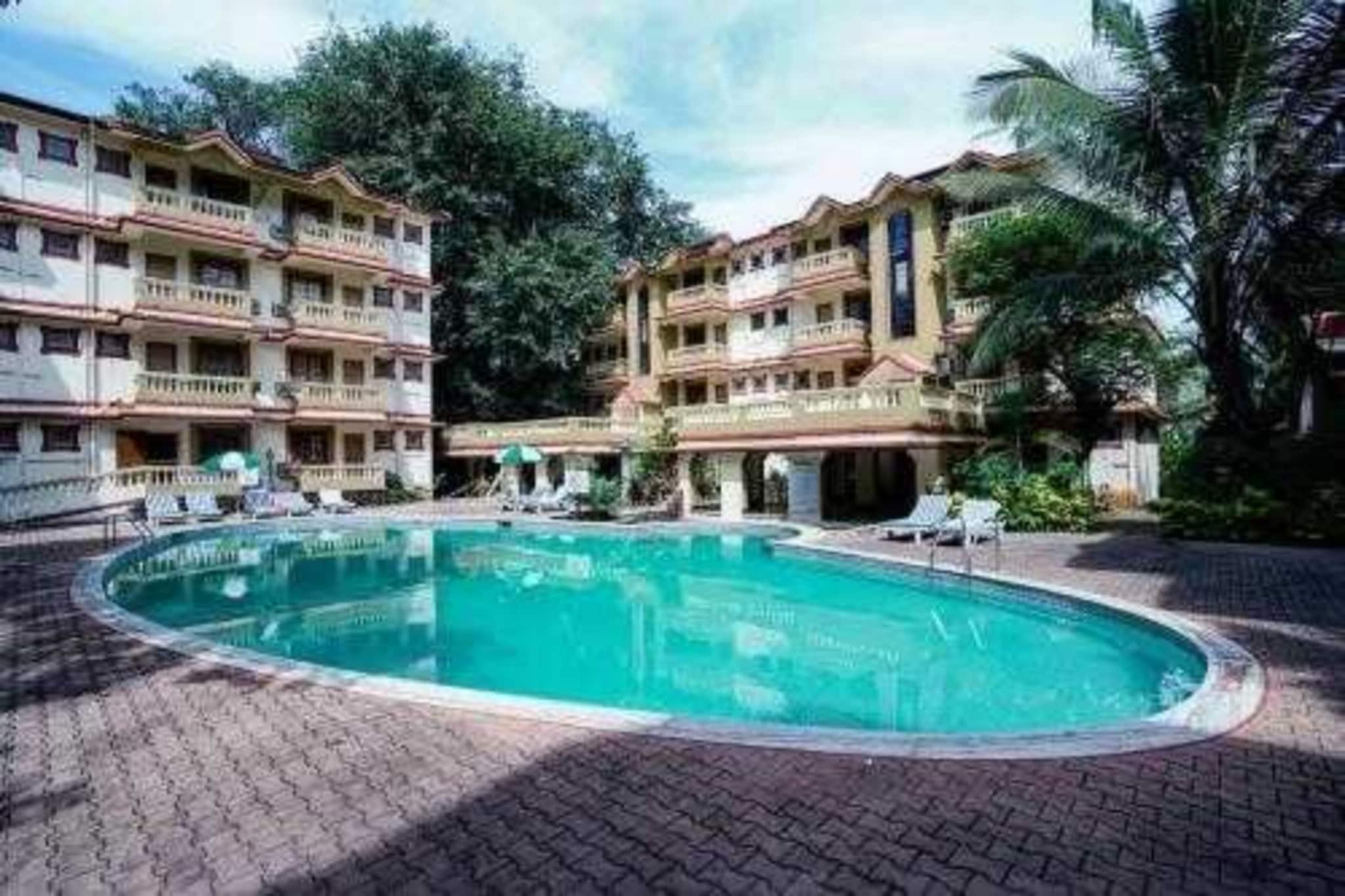 Palette Homes – Susegad (3BHK Apartment)
Just minutes away from Calangute and Candolim Beach, and surrounded by popular nightclubs and restaurants like Tomatoes, Hammerz, and VagaluMME, this premium apartment offers you the perfect Goan getaway.
Accommodation
Enjoy the comfort of a 3BHK apartment designed for families and groups. With three queen-sized bedrooms, private bathrooms, and spacious living areas, the apartment combines homely comfort with a coastal vibe.
Villa Amenities
✔ Common Pool & Poolside Lawn
✔ LED TV (55â€)
✔ Coffee/Tea Maker
✔ Refrigerator & RO Purifier
✔ Modular Kitchen (with toaster, stove, cutlery & crockery)
✔ Geyser & Toiletries
✔ High-speed Wi-Fi
✔ Parking
Bedrooms
•     Bedroom 1: Queen-sized bed | Ensuite bathroom | AC | Fan | Wardrobe space | Work/study desk | Sofa chair
•     Bedroom 2: Queen-sized bed | AC | Fan | Wardrobe space | Work/study desk | Sofa chair
•     Bedroom 3: Queen-sized bed | AC | Fan | Wardrobe space | Work/study desk | Sofa chair
Bathrooms
Each ensuite bathroom is equipped with:
🚿 Shower | Geyser | Hand jet spray | Organic toiletries & towels | Western commode
Living & Dining
•     Living Room: Sofa seating with a center table | 55†TV | AC | Fans
•     Dining: 6-seater dining table near the living room (Ground Floor)
Kitchen
A fully equipped open kitchen with ample storage space and all necessary appliances:
Refrigerator | Oven | Microwave | Kettle | Rice cooker | Cooking utensils
Dine
🴠The villa comes with a fully equipped kitchen, giving you the flexibility to prepare both veg & non-veg meals.
Nearby Attractions
📠Baga Beach
📠Calangute Beach (2 mins)
📠Candolim Beach (2 mins)
📠Nightclubs like Hammerz
📠Popular Cafés & Restaurants like Tomatoes, Fisherman’s Wharf
Closing Line
Stay at Palette Homes – Susegad for a perfect blend of comfort, convenience, and coastal charm — making your Goan holiday unforgettable.