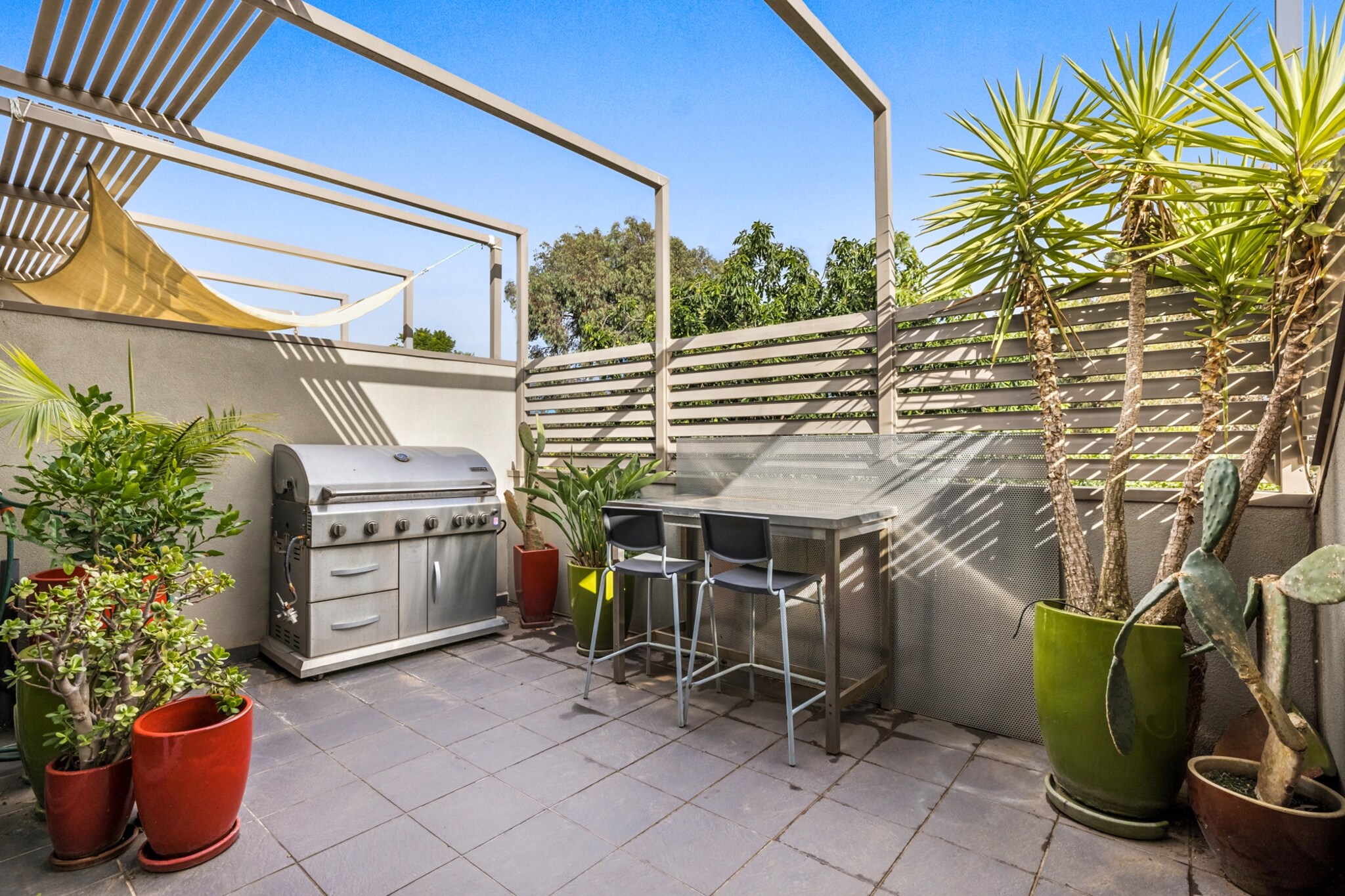 This is a beautiful two-bedroom apartment with garage parking in the centre of Northcote, a few minutes’ walk from the restaurants, cafes, bars and shops along High Street. It’s also 35 minutes from the Melbourne CBD via tram. The unit offers excellent living space with its open-plan living and dining rooms and well-equipped kitchen. It caters to little ones with two single beds in one bedroom and a shower bath. Outdoor entertaining is ideal on the sun-drenched patio, which has a barbecue.
The space
This is a stunning apartment spread across one floor. Its main living area is adorned with polished timber flooring and ample natural light. It has leather lounges, four-person dining and a well-equipped kitchen. There are two bedrooms that share a bathroom, including one bedroom with two single beds. It also has a sunny patio with a barbecue.
 
General
-Entire 2-bedroom, 1-bathroom apartment
-Private BBQ patio
-Air conditioning
-Laundry facilities provided
-Wi-Fi provided
-Secure garage parking
- Free off street parking
 
Living room
-Flat-screen TV
-Large sofa
-Coffee table
-Dining table
-Air conditioning
 
Bedrooms and bathrooms
-Bedroom 1: Queen-size bed, walk-in wardrobe, blackout blinds
-Bedroom 2: 2 single beds, built-in wardrobe, blackout blinds
-One bathroom with shower bath
-Top quality linens & towels
 
Kitchen
-Stainless-steel meile appliances
-Electric oven and stovetop with rangehood
-Dishwasher
-Toaster, microwave and kettle
-Large fridge and freezer
 
Laundry
-Iron and ironing board
-Washing machine and dryer
-Clothes drying rack
 
Points of Interests
- Northcote Plaza Shopping Centre 1.0 Km, 15-minutes walk
- All Nations Park 1.1 Km, 15-minutes walk
- Northcote Town Hall Arts Centre 0.3 Km, four-minutes walk
 
Beach Access
- Port Melbourne Beach 11.4 Km, 20-minutes drive
- St Kilda Beach 11.1 Km, 20-minutes drive
 
Airport Access
- Melbourne Airport 22.2 Km, 25-minutes drive
- Avalon Airport 62.8 Km, 55-minutes drive
Local area description
Northcote is a village-style suburb north of Melbourne’s city centre. It’s a trendy neighbourhood that’s become renowned for its live music, particularly at Northcote Social Club. Stroll down High Street to browse indie shops and duck into hipster bars, cafes and cosmopolitan restaurants. Northcote is also dotted with lush parkland and is ideal for indulging in Italian and Greek cuisine.
House rules
You are staying in a friendly and peaceful neighbourhood and we kindly ask you to respect the community and your surrounding neighbours. The following strict House Rules apply:
 
- No loud noise between 10 pm and 8 am
- No parties or antisocial behaviour
- No additional people are to access the property without our prior approval
- No pets are allowed in the property without approval
- No smoking is allowed at any times
- If you break something, please let us know
- To help protect all floor coverings do not wear any shoes inside the property
 
Please be aware that excessive noise such as amplified music, vocals or screaming or anti-social behaviour in the property or common areas can cause neighbours to complain to us, the Building Manager, Council Rangers or Police.
 
IMPORTANT: Any breach of the House Rules may lead to a $500 fine plus compensation for any cost/damage created and immediate eviction of the property.
 
Finally, when checking out, we kindly ask you for the following:
 
- Please leave all beds unmade
- Please clean up your dishes and put them away
- In case you have rearranged furniture, please put it back to the original location
- Please take out the rubbish and remember to use the right bins
- Please ensure all appliances, A/C and lights are off and doors and windows are closed
Interaction with guests
Welcome to MadeComfy! Our local team curates stays in exceptional Australian & New Zealand properties, ensuring style, comfort, and prime locations for discerning guests. We prioritise your needs to provide a memorable home-away-from-home experience. Explore our digital guidebooks for local recommendations, and don't hesitate to contact us throughout your stay. We're here to ensure your comfort – enjoy your stay with MadeComfy.
Notes
For your comfort, this property is prepared with professional-grade hotel-style linen, including a three-sheet setup, ensuring a fresh and hygienic sleep experience.
 
Extra Services:
- Early check-in: Our standard check-in is at 3 pm. To guarantee early access to the property we suggest booking the night before if available. Otherwise, early check-in is subject to availability from the night before at an additional cost.
- Late check-out: Our standard check-out is at 10 am. To guarantee a later check-out of the property we suggest booking an additional night if available. Otherwise, a late check-out is subject to availability from the night before to an additional cost.
- Baggage: For security reasons, we are unable to receive or to keep unattended baggage before check-in or after check-out
- We provide a small welcome amenity pack to get your stay started
 
- Air conditioning is in the living area only.
- Close to two train stations
 
Note
- Parking has a vehicle height limit of 2m
- Air conditioning in living room only
- This booking is protected with coverage for lost baggage and emergency medical expenses, provided by Travel Support with claim upto 500 AUD (T&C Applies). For more details reach out to Guest Support team post booking.
Access description
You’ll have access to the entire property when you stay here, so it will feel like your own home.
Getting around
We highly recommend using ride-sharing services.
 
Check out the TripGo app for transport timetables.
 
Public transport
The Northcote Town Hall/High St tram stop is about 300 metres from the apartment and has lines servicing the CBD in about 30 minutes. Northcote Station is about 1 kilometre away and has multiple trains servicing numerous Melbourne neighbourhoods and the CBD.
 
Ride sharing
Ride sharing apps are a safe and easy way to get around, especially late at night when public transport services are less frequent. Prices are about two-thirds of a taxi, but may surge during bad weather or public events.
 
Points of Interests
- Northcote Plaza Shopping Centre 1.0 Km, 15-minutes walk
- All Nations Park 1.1 Km, 15-minutes walk
- Northcote Town Hall Arts Centre 0.3 Km, four-minutes walk
 
Beach Access
- Port Melbourne Beach 11.4 Km, 20-minutes drive
- St Kilda Beach 11.1 Km, 20-minutes drive
 
Airport Access
- Melbourne Airport 22.2 Km, 25-minutes drive
- Avalon Airport 62.8 Km, 55-minutes drive