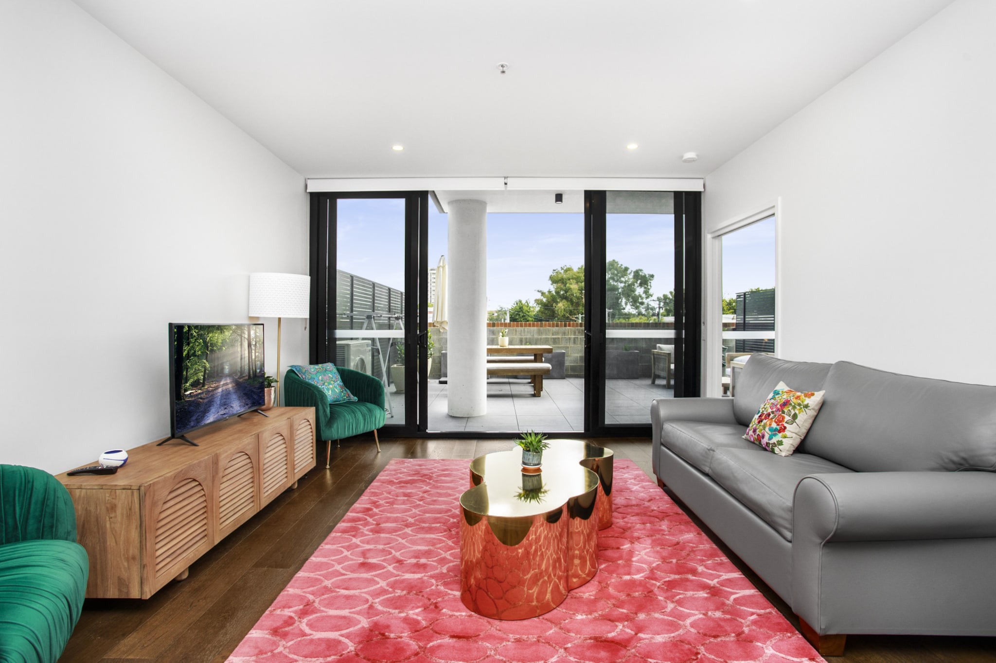 This one-bedroom apartment is about 10 minutes’ drive from the Canberra CBD. It’s even closer to the Jerrabomberra Wetlands, Old Parliament House and National Gallery of Australia. It’s also surrounded by Kingston’s trendiest cafes, bars and restaurants and has great bus links and secure on-site parking. The apartment has a comfy bedroom and living/dining area, as well as a sleek kitchen with modern appliances. It opens out onto a large terrace with lounge seating and umbrellaed outdoor dining.

The space
This one-bedroom apartment has chic furnishings with velvet and leather finishes. It can accommodate up to four guests with its main bedroom and a sofa bed in the living room. The kitchen offers ample cooking and storage space, along with modern appliances. It also has a tiled bathroom with a laundry. The main draw is its sprawling terrace with lounge seating and an umbrellaed dining table.
 
General
- Entire one-bedroom apartment
- Secure parking
- Central heating and air conditioning
- Laundry facilities available
- Wi-Fi is provided
- Alfresco terrace with lounge seating and outdoor dining
- 4 guests with sofa bed
- Self check-in
 
Living room
- Smart TV
- Sofa bed
- Dining table
- Coffee table
- Air conditioning
 
Bedrooms and bathrooms
- Bedroom: Queen-size bed, blackout blinds, built-in wardrobe, ensuite
- Separate toilet in laundry
- Top quality linens & towels
 
Kitchen
- Stainless-steel appliances
- Oven and stovetop with rangehood
- Dishwasher
- Toaster, kettle and microwave
- Fridge and freezer
 
Laundry
- Washing machine
- Iron and ironing board
 
Points of Interest
- Old Parliament House 3.0 Km, 28-minutes walk or five-minutes drive
- Kingston Foreshore 0.7 Km, nine-minutes walk or two-minutes drive
- Manuka Shopping Precinct 1.3 Km, 15-minutes walk or three-minutes drive
 
Airport Access
- Canberra Airport 8.4 Km, nine-minutes drive
Local area description
Kingston is a leafy neighbourhood nestled on Canberra’s beautiful waterways. The Kingston Foreshore is a popular spot for waterfront dining and browsing art galleries, while its town centre has trendy cafes and bars. The neighbourhood is also a great place to check out local markets and discover verdant nature in Jerrabomberra Wetlands Nature Reserve.
House rules
You are staying in a friendly and peaceful neighbourhood and we kindly ask you to respect the community and your surrounding neighbours. The following strict House Rules apply:
- No loud noise between 10 pm and 8 am
- No parties or antisocial behaviour
- No additional people are to access the property without our prior approval
- No pets are allowed in the property without approval
- No smoking is allowed at any times
- If you break something, please let us know
- To help protect all floor coverings do not wear any shoes inside the property
 
Please be aware that excessive noise such as amplified music, vocals or screaming or anti-social behaviour in the property or common areas can cause neighbours to complain to us, the Building Manager, Council Rangers or Police.
 
IMPORTANT: Any breach of the House Rules may lead to a $500 fine plus compensation for any cost/damage created and immediate eviction of the property.
 
Finally, when checking out, we kindly ask you for the following:
- Please leave all beds unmade
- Please clean up your dishes and put them away
- In case you have rearranged furniture, please put it back to the original location
- Please take out the rubbish and remember to use the right bins
- Please ensure all appliances, A/C and lights are off and doors and windows are closed
Interaction with guests
Welcome to MadeComfy! Our local team curates stays in exceptional Australian & New Zealand properties, ensuring style, comfort, and prime locations for discerning guests. We prioritise your needs to provide a memorable home-away-from-home experience. Explore our digital guidebooks for local recommendations, and don't hesitate to contact us throughout your stay. We're here to ensure your comfort – enjoy your stay with MadeComfy.
Notes
For your comfort, this property is prepared with professional-grade hotel-style linen, including a three-sheet setup, ensuring a fresh and hygienic sleep experience.
 
Extra Services:
- Early check-in: Our standard check-in is at 3 pm. To guarantee early access to the property we suggest booking the night before if available. Otherwise, early check-in is subject to availability from the night before at an additional cost.
- Late check-out: Our standard check-out is at 10 am. To guarantee a later check-out of the property we suggest booking an additional night if available. Otherwise, a late check-out is subject to availability from the night before to an additional cost.
- Baggage: For security reasons, we are unable to receive or to keep unattended baggage before check-in or after check-out
- We provide a small welcome amenity pack to get your stay started
 
Note
- Limited street parking is also available
- Central air conditioning and heating in living room
- This booking is protected with coverage for lost baggage and emergency medical expenses, provided by Travel Support with claim upto 500 AUD (T&C Applies). For more details reach out to Guest Support team post booking.
Access description
You’ll have access to the entire property when you stay here, so it will feel like your own home.
- The keys will be left in a lockbox onsite. We will send you the access code 3 days prior to your arrival through the booking portal.
Getting around
We highly recommend using ride-sharing services.
 
Check out the TripGo app for transport timetables.
 
Public transport
The Kingston Shops/Eyre Street bus stop is right outside the building. It has multiple lines to the CBD in about 20 minutes. Canberra Railway Station is about 900 metres away and has regular services to outer suburbs and beyond the state border.
 
Ride sharing
Ride sharing apps are a safe and easy way to get around, especially late at night when public transport services are less frequent. Prices are about two-thirds of a taxi, but may surge during bad weather or public events.
 
Points of Interest
- Old Parliament House 3.0 Km, 28-minutes walk or five-minutes drive
- Kingston Foreshore 0.7 Km, nine-minutes walk or two-minutes drive
- Manuka Shopping Precinct 1.3 Km, 15-minutes walk or three-minutes drive
 
Airport Access
- Canberra Airport 8.4 Km, nine-minutes drive