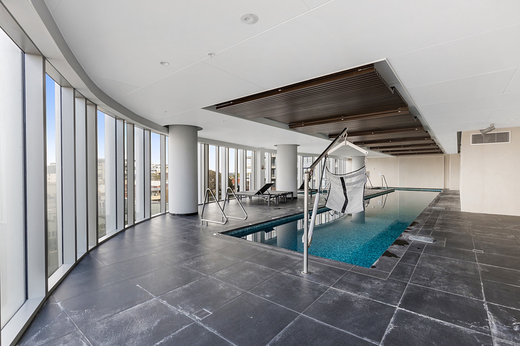 Located in the centre of Moonee Ponds’ dining and shopping hub, this apartment is a stunning holiday pad with great perks. The unit is immaculately styled with open-plan living and a designer kitchen overlooking the suburban sprawl through floor-to-ceiling windows. These vistas flow into the cosy bedroom, which also has a balcony. You also have access to the complex’s elegant Sky Bar and communal pool, barbecue, sauna and gym. Secure parking and nearby trains make it easy to explore Melbourne.
The space
Located on the 27th floor of a high rise, this apartment is a well-designed residence with modern features and incredible neighbourhood views through floor-to-ceiling windows. It has a designer kitchen with bench seating, an expansive sofa and a balcony with outdoor seating. The bathroom has a rain shower, while the bedroom has double bed size and balcony access. Timber and marble finishes flow throughout.
 
General
- Entire one-bedroom apartment
- Air conditioning provided
- Laundry facilities provided
- Wi-Fi is provided
- Furnished balcony
- Secure parking
- Sprawling neighbourhood views
- Communal gym, pool, sauna, steam room and terrace with BBQ
- Rooftop Sky Bar
- Self check-in
 
Living room
- Flat-screen TV
- Sofa
- Air conditioning
 
Bedrooms and bathrooms
- Bedroom: Double bed, blackout blinds, built-in wardrobe, balcony access
- Bathroom with rain shower
- Top quality linens & towels
 
Kitchen
- Modern stainless-steel appliances
- Electric oven and induction stovetop with rangehood
- Dishwasher
- Toaster, microwave and kettle
- Fridge and freezer
- Breakfast bar
 
Laundry
- Washing machine and dryer
- Clothes drying rack
Local area description
Located about seven kilometres north of the Melbourne CBD, Moonee Ponds is best-known for the picturesque Queens Park and regular racing events at Moonee Valley Racecourse. The suburb’s shopping and dining area is spread across Puckle Street, Hall Street and Homer Street, providing visitors with bars, alfresco cafes and multicultural restaurants. Its own little community, Moonee Ponds is also home to The Clocktower Centre performing arts theatre and Moonee Ponds Central Shopping Centre.
House rules
You are staying in a friendly and peaceful neighbourhood and we kindly ask you to respect the community and your surrounding neighbours. The following strict House Rules apply:
- No loud noise between 10 pm and 8 am
- No parties or antisocial behaviour
- No additional people are to access the property without our prior approval
- No pets are allowed in the property without approval
- No smoking is allowed at any times
- If you break something, please let us know
- To help protect all floor coverings do not wear any shoes inside the property
 
Please be aware that excessive noise such as amplified music, vocals or screaming or anti-social behaviour in the property or common areas can cause neighbours to complain to us, the Building Manager, Council Rangers or Police.
 
IMPORTANT: Any breach of the House Rules may lead to a $500 fine plus compensation for any cost/damage created and immediate eviction of the property.
 
Finally, when checking out, we kindly ask you for the following:
- Please leave all beds unmade
- Please clean up your dishes and put them away
- In case you have rearranged furniture, please put it back to the original location
- Please take out the rubbish and remember to use the right bins
- Please ensure all appliances, A/C and lights are off and doors and windows are closed
Interaction with guests
Welcome to MadeComfy! Our local team curates stays in exceptional Australian & New Zealand properties, ensuring style, comfort, and prime locations for discerning guests. We prioritise your needs to provide a memorable home-away-from-home experience. Explore our digital guidebooks for local recommendations, and don't hesitate to contact us throughout your stay. We're here to ensure your comfort – enjoy your stay with MadeComfy.
Notes
For your comfort, this property is prepared with professional-grade hotel-style linen, including a three-sheet setup, ensuring a fresh and hygienic sleep experience.
 
Extra Services:
- Early check-in: Our standard check-in is at 3 pm. To guarantee early access to the property we suggest booking the night before if available. Otherwise, early check-in is subject to availability from the night before at an additional cost.
- Late check-out: Our standard check-out is at 10 am. To guarantee a later check-out of the property we suggest booking an additional night if available. Otherwise, a late check-out is subject to availability from the night before to an additional cost.
- Baggage: For security reasons, we are unable to receive or to keep unattended baggage before check-in or after check-out
- We provide a small welcome amenity pack to get your stay started
 
Note
- BBQ located on level 4 inside the terrace
- Gym, steam room and sauna are located on level 3
- Pool is located on level 4
- Parking has a vehicle height limit of 2.2m
- Sky Bar located on level 22
- Air conditioning throughout
- This booking is protected with coverage for lost baggage and emergency medical expenses, provided by Travel Support with claim upto 500 AUD (T&C Applies). For more details reach out to Guest Support team post booking.
Access description
You’ll have access to the entire property when you stay here, so it will feel like your own home.
- The key collection is located offsite, around 200 meters away from the property, and not available 24/7. Further details will be provided 3 days before check-in if your booking is successfully reserved.
Getting around
We highly recommend using ride-sharing services.
Check out the TripGo app for transport timetables.
 
Public transport
Moonee Ponds Station is 260 metres away and has regular trains to the Melbourne CBD in about 25 minutes. The Moonee Ponds Junction tram station is about 350 metres away and has regular services into the CBD in 30 minutes. There are also bus stops around Moonee Ponds Junction with multiple lines servicing the city centre.
 
Ride sharing
Ride sharing apps are a safe and easy way to get around, especially late at night when public transport services are less frequent. Prices are about two-thirds of a taxi, but may surge during bad weather or public events.
 
Points of Interest
- Moonee Ponds Central Shopping Centre 0.07 Km, one-minutes walk
- Queens Park 0.6 Km, eight-minutes walk or three-minutes drive
- Moonee Valley Racecourse 0.9 Km, 12-minutes walk or five-minutes drive
 
Beach Access
- Port Melbourne Beach 12.7 Km, 17-minutes drive
- St Kilda Beach 15.5 Km, 21-minutes drive
 
Airport Access
- Melbourne Airport 13.6 Km, 13-minutes drive
- Avalon Airport 54.3 Km, 46-minutes drive