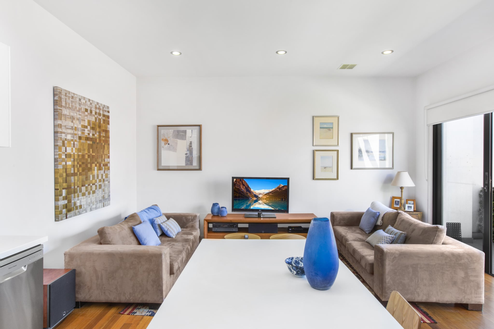 This two-bedroom apartment has ample living, dining and sleeping space. It’s a modern home with open-plan living and dining and a large kitchen ideal for socialising or cosy nights in. Enjoy drinks and meals on the sunny furnished balcony. Other creature comforts include high-end appliances, a well-stocked bookshelf and fast Wi-Fi. Free parking and a nearby train station make it easy to access the Melbourne CBD, only 15 minutes away. You can also walk to Yarraville’s dining strip and parks.
The space
This two-bedroom apartment is adorned with timber floors, comfortable furnishings and an abundance of natural light. It’s the perfect space for friends or couples looking for a quiet holiday home close to Melbourne’s city centre. It offers ample space for socialising and relaxing, whether inside around the designer kitchen or out on the balcony.
 
General
- Entire two-bedroom apartment
- Private furnished balcony
- Laundry facilities provided
- Wi-Fi provided
- Secure undercover parking
 
Living room
- Flat-screen TV
- Sofas
- Coffee table
- Dining table
 
Bedrooms and bathrooms
- Bedroom 1: Queen-size bed, bookshelf, blackout blinds
- Bedroom 2: Queen-size bed, chest of drawers, blackout blinds
- Bathroom with hairdryer
- Top quality linens & towels
 
Kitchen
- Modern stainless-steel appliances
- Electric oven and stovetop with rangehood
- Large fridge and freezer
- Microwave, kettle and toaster
- Dishwasher
 
Laundry
- Washing machine and dryer
- Clothes drying rack
- Iron and ironing board