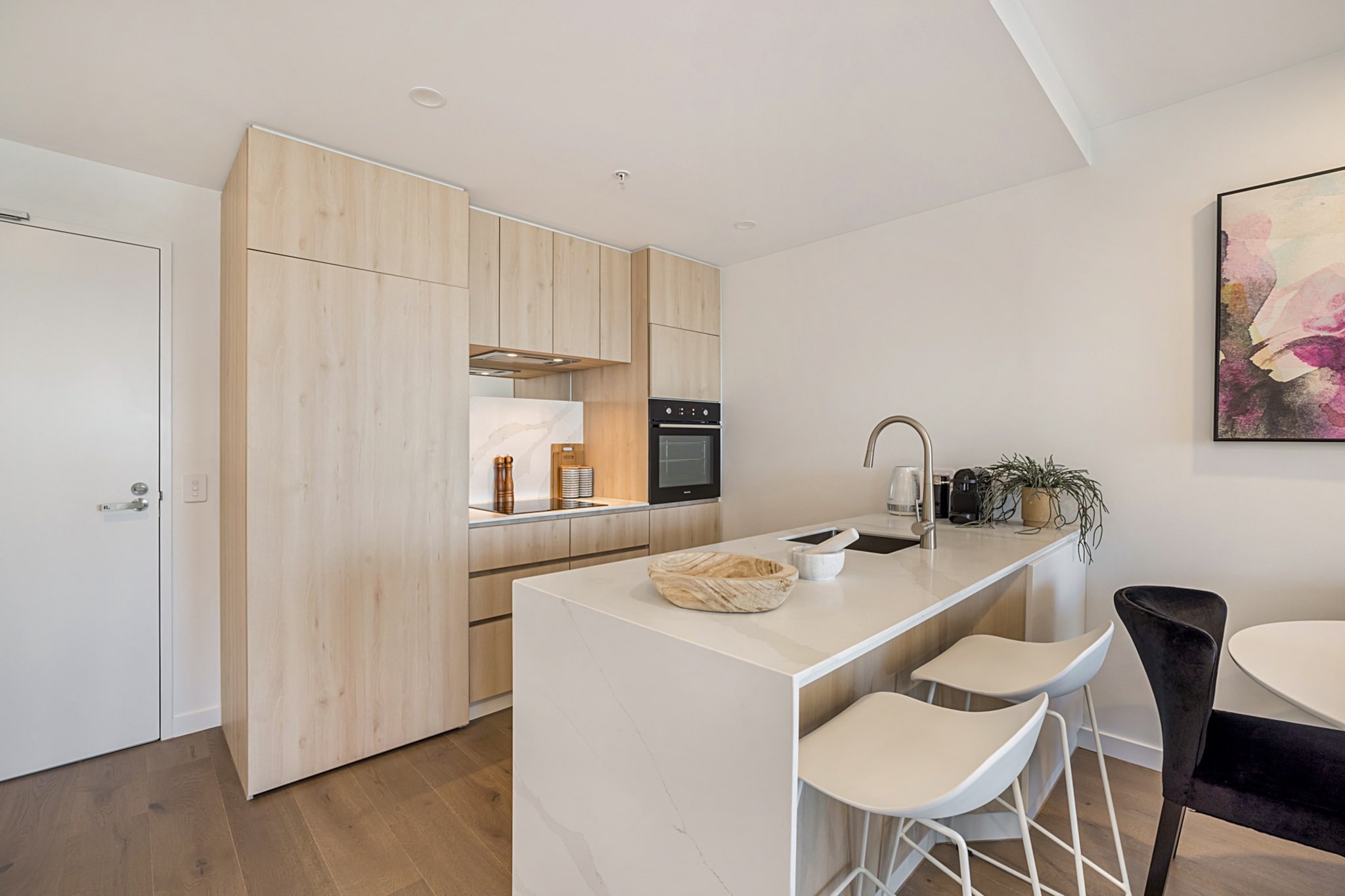 This stylish one-bedroom apartment offers access to a barbecue terrace, indoor lap pool, gym and sauna. You also have secure undercover parking and a gorgeous private balcony with sweeping neighbourhood views. The living and dining area, complete with a designer kitchen, caters to movie nights and dinner parties. You’re also metres from restaurants, bars, cafes, Moonee Ponds Central Shopping Centre, Moonee Ponds Station and Moonee Valley Racecourse. The Melbourne CBD is a 25-minute train away.
The space
Located on the 20th floor of a high rise, this apartment offers a modern space with comfortable living and dining areas, a designer kitchen and contemporary bathroom. It also offers excellent views from its cosy bedroom and furnished balcony.
 
General
- Entire one-bedroom apartment
- Air conditioning provided
- Laundry facilities provided
- Wi-Fi is available
- Furnished balcony
- Secure parking
- Communal gym, pool, sauna and terrace with BBQ
 
Living room
- Flat-screen TV
- Sofa
- Coffee table
- Dining table
- Air conditioning
 
Bedrooms and bathrooms
- Bedroom: Queen-size bed, blackout blinds, built-in wardrobe
- One bathroom with hairdryer
- Top quality linens & towels
 
Kitchen
- Modern stainless-steel appliances
- Electric oven and induction stovetop with rangehood
- Dishwasher
- Toaster, microwave, coffee machine and kettle
- Fridge and freezer
- Breakfast bar
 
Laundry
- Iron and ironing board
- Washing machine and dryer
- Clothes drying rack