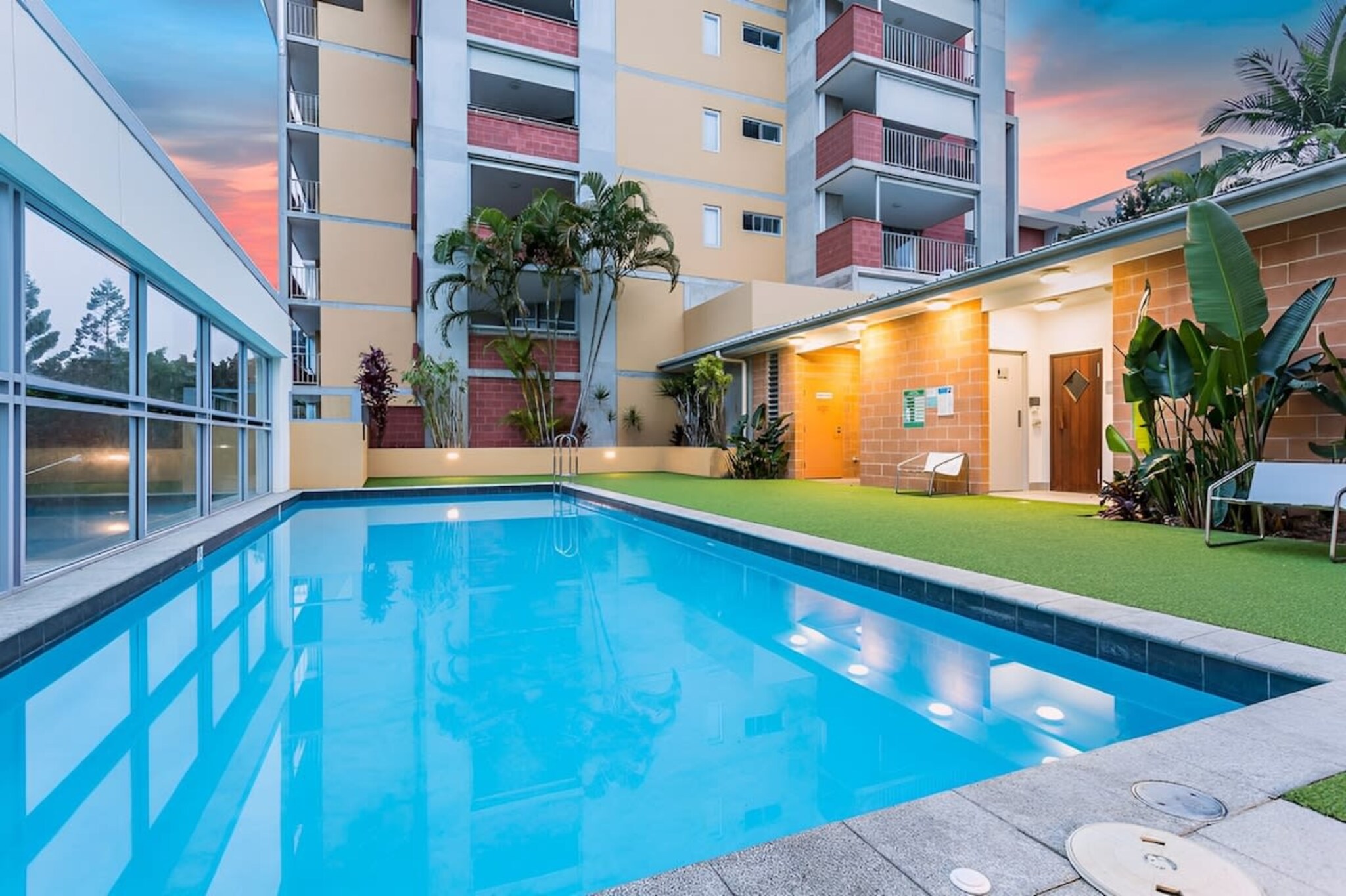 Close enough to the action in the CBD, but away enough to relax from the hustle and bustle of it all, this apartment will have you spoilt for choice when it comes to how you want your stay in Brisbane to play out. Located in the beautiful suburb of Kelvin Grove, this split level apartment is the perfect city Airbnb for long or short trips. Featuring 2 king bedrooms, free parking, laundry facilities, dishwasher, a generous outdoor entertainment area with BBQ and pool and sauna access.
The space
This wonderful home is situated moments from Brisbane CBD and Paddington shopping villages and a short trip to the CBD. Fully furnished and close to all necessities, this bright home features spacious entertaining areas, a fully equipped kitchen, and everything you’ll possibly need for a comfortable stay.
General
- Contemporary styling and furniture
- BBQ and pool and sauna access
- Laundry facilities provided
- Footsteps to a shopping centre with buses, minutes to the city
- Outdoor entertainment area
- Free parking
- Wi-Fi is provided
- Self check-in
Kitchen
- Gas stovetop and cookware
- Modern stainless-steel appliances
- Kettle, toaster, dishwasher, oven, coffee machine and microwave
Living/dining area
- Flat-screen smart TV
- Spacious lounge with pillows
- Dining table for four
Bedrooms
- Blackout blinds for optimal sleep
- 2 Queen bedrooms
Bathroom
- Clean bathroom with walk-in shower
- Travel essentials and hairdryer provided
- Toiletries and towels provided
Points of Interest
- Rosalie Shopping village with a gourmet market, Blue Room Cinebar, pharmacy, grocery store and range of restaurants 3.4 Km, six-minutes drive
- Milton Markets and shopping village 2.4 Km, four-minutes drive
- Brisbane CBD 5.4 Km, nine-minutes drive
- Fortitude Valley 4.9 Km, six-minutes drive
Airport Access
- Brisbane Airport 14.3 Km, 15-minutes drive
Local area description
This is a great family suburb. Close to everything and major infrastructure is about to commence including Metro rail and redevelopment of the Victoria Park Golf course into a great green space for the whole family. You are within walking distance of the city and the Valley if you chose or you can catch one of many buses that go past to both locations. It is a hilly suburb with great cooling breezes in summer. Local pubs, shops, restaurants are excellent with a massive choice. The local school has an excellent name and many links to the Uni which is also located in the suburb. There are a local golf course, hospital and uni on your doorsteps. You have easy access to all areas of Brisbane via the many new major roads and tunnels that make getting around easy. You have two major sporting grounds within walking distance, you have so many options for food and everyday shopping you are spoiled for choice. The urban village is great hosting a local Kelvin Grove Farmers market which is held every Saturday on the street next to the complex, but there is so much more to the suburb. It is a great little secret that is only 2 suburbs away from the CBD.
House rules
You are staying in a friendly and peaceful neighbourhood and we kindly ask you to respect the community and your surrounding neighbours. The following strict House Rules apply:
- No loud noise between 10 pm and 8 am
- No parties or antisocial behaviour
- No additional people are to access the property without our prior approval
- No pets are allowed in the property without approval
- No smoking is allowed at any times
- If you break something, please let us know
- To help protect all floor coverings do not wear any shoes inside the property
Please be aware that excessive noise such as amplified music, vocals or screaming or anti-social behaviour in the property or common areas can cause neighbours to complain to us, the Building Manager, Council Rangers or Police.
IMPORTANT: Any breach of the House Rules may lead to a $500 fine plus compensation for any cost/damage created and immediate eviction of the property.
Finally, when checking out, we kindly ask you for the following:
- Please leave all beds unmade
- Please clean up your dishes and put them away
- In case you have rearranged furniture, please put it back to the original location
- Please take out the rubbish and remember to use the right bins
- Please ensure all appliances, A/C and lights are off and doors and windows are closed
Interaction with guests
Welcome to MadeComfy! Our local team curates stays in exceptional Australian & New Zealand properties, ensuring style, comfort, and prime locations for discerning guests. We prioritise your needs to provide a memorable home-away-from-home experience. Explore our digital guidebooks for local recommendations, and don't hesitate to contact us throughout your stay. We're here to ensure your comfort – enjoy your stay with MadeComfy.
Notes
- For your comfort, this property is prepared with professional-grade hotel-style linen, including a three-sheet setup, ensuring a fresh and hygienic sleep experience.
- Building works currently happening
Extra Services:
- Early check-in: Our standard check-in is at 3 pm. To guarantee early access to the property we suggest booking the night before if available. Otherwise, early check-in is subject to availability from the night before at an additional cost.
- Late check-out: Our standard check-out is at 10 am. To guarantee a later check-out of the property we suggest booking an additional night if available. Otherwise, a late check-out is subject to availability from the night before to an additional cost.
- Baggage: For security reasons, we are unable to receive or to keep unattended baggage before check-in or after check-out
- We provide a small welcome amenity pack to get your stay started
- This booking is protected with coverage for lost baggage and emergency medical expenses, provided by Travel Support with claim upto 500 AUD (T&C Applies). For more details reach out to Guest Support team post booking.
Access description
You’ll have access to the entire property when you stay here, so it will feel like your own home.
- The keys will be left in a lockbox onsite. We will send you the access code 3 days prior to your arrival through the booking portal.
Getting around
We highly recommend using ride-sharing services.
Check out the TripGo app for transport timetables.
Points of Interest
- Rosalie Shopping village with a gourmet market, Blue Room Cinebar, pharmacy, grocery store and range of restaurants 3.4 Km, six-minutes drive
- Milton Markets and shopping village 2.4 Km, four-minutes drive
- Brisbane CBD 5.4 Km, nine-minutes drive
- Fortitude Valley 4.9 Km, six-minutes drive
Airport Access
- Brisbane Airport 14.3 Km, 15-minutes drive