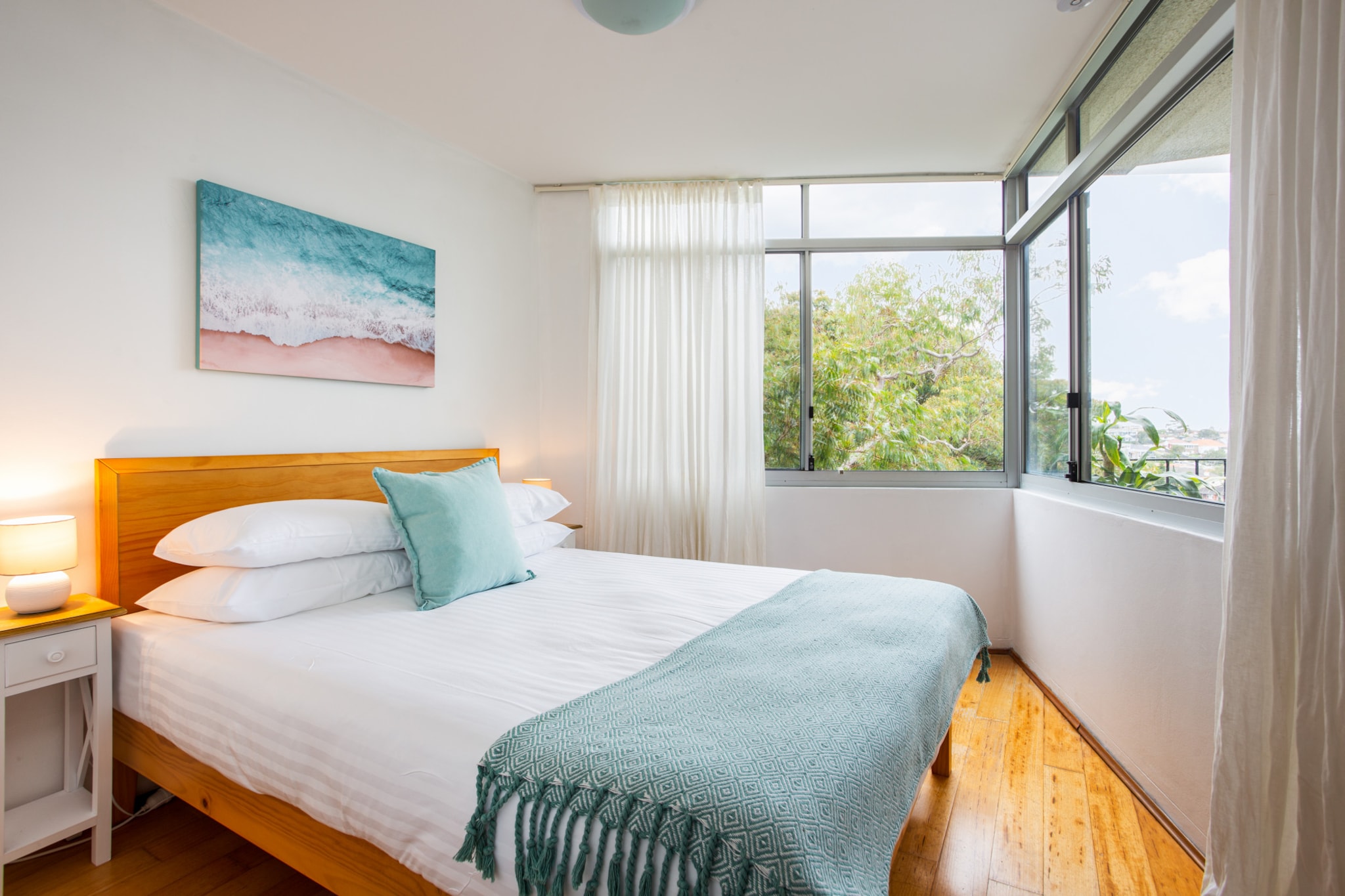 This is a beautiful, sunlit unit minutes’ walk from the shops, bars and restaurants along Bronte Road and the golden sand of Bronte Beach. It’s also a 10-minute walk from Bronte Park, Bronte Baths and Tamarama Beach. The unit is surrounded by verdant trees and has stunning ocean and sunrise views. It has a great kitchen, two dining areas and a cosy living room. The bedroom and furnished balcony overlook the leafy treetops and water. Nearby train station make exploring Sydney easy.
The space
This apartment is both cosy and open with numerous windows catching an abundance of natural light and leafy views. The wooden floors and thoughtful furnishings are particularly inviting. The main living area includes a convenient kitchen, two-person dining table, timber bench with stools and a comfortable sofa. There’s also a queen-size bed and balcony with outdoor seating.
General
- Private furnished balcony
- Ocean view
- Wi-Fi provided
- Unlimited on-street parking
- Close to public transport
- Walking distance to Bondi, Bronte and Coogee beaches
 
Living room
- Smart TV with Netflix
- Sofa
- Coffee table
- Dining table
 
Bedrooms and bathrooms
- Bedroom: Queen-size bed, built-in wardrobe, curtains
- Bathroom with hair dryer
- Top quality linens & towels
 
Kitchen
- Stainless-steel appliances
- Electric fan forced oven, ceramic dual hob stovetop and range hood.
- Toaster, kettle, coffee machine and microwave
- Fridge and freezer
 
Points of Interests
- Westfield Bondi Junction 1.9 Km, five-minutes drive
- Bronte Park 0.65 Km, ten-minutes walk
- Bronte Baths 2.0 Km, five-minutes drive
 
Beach Access
Bronte Beach 1.4 Km, four-minutes drive
Tamarama Beach 1.8 Km, four-minutes drive
 
Airport Access
Sydney Airport 12.6 Km, 20-minutes drive
Local area description
Located about seven kilometres from the Sydney CBD, Waverley is a charming suburb along the New South Wales coastline. The neighbourhood centres around a lovely shopping and dining strip along Bronte Road, complete with vintage sellers, pubs and Asian eateries. Waverley is also a great launching pad for visiting Bronte Beach, Tamarama Beach and Bondi Beach, along with Queens Park and the Bronte Baths.
House rules
You are staying in a friendly and peaceful neighbourhood and we kindly ask you to respect the community and your surrounding neighbours. The following strict House Rules apply:
 
- No loud noise between 10 pm and 8 am
- No parties or antisocial behaviour
- No additional people are to access the property without our prior approval
- No pets are allowed in the property without approval
- No smoking is allowed at any times
- If you break something, please let us know
- To help protect all floor coverings do not wear any shoes inside the property
 
Please be aware that excessive noise such as amplified music, vocals or screaming or anti-social behaviour in the property or common areas can cause neighbours to complain to us, the Building Manager, Council Rangers or Police.
 
IMPORTANT: Any breach of the House Rules may lead to a $500 fine plus compensation for any cost/damage created and immediate eviction of the property.
 
Finally, when checking out, we kindly ask you for the following:
 
- Please leave all beds unmade
- Please clean up your dishes and put them away
- In case you have rearranged furniture, please put it back to the original location
- Please take out the rubbish and remember to use the right bins
- Please ensure all appliances, A/C and lights are off and doors and windows are closed
Interaction with guests
Welcome to MadeComfy! Our local team curates stays in exceptional Australian & New Zealand properties, ensuring style, comfort, and prime locations for discerning guests. We prioritise your needs to provide a memorable home-away-from-home experience. Explore our digital guidebooks for local recommendations, and don't hesitate to contact us throughout your stay. We're here to ensure your comfort – enjoy your stay with MadeComfy.
Notes
For your comfort, this property is prepared with professional-grade hotel-style linen, including a three-sheet setup, ensuring a fresh and hygienic sleep experience.
 
Extra Services:
- Early check-in: Our standard check-in is at 3 pm. To guarantee early access to the property we suggest booking the night before if available. Otherwise, early check-in is subject to availability from the night before at an additional cost.
- Late check-out: Our standard check-out is at 10 am. To guarantee a later check-out of the property we suggest booking an additional night if available. Otherwise, a late check-out is subject to availability from the night before to an additional cost.
- Baggage: For security reasons, we are unable to receive or to keep unattended baggage before check-in or after check-out
- We provide a small welcome amenity pack to get your stay started
 
Note
- No air conditioning
- No dishwasher
- No Pets Allowed
- This booking is protected with coverage for lost baggage and emergency medical expenses, provided by Travel Support with claim upto 500 AUD (T&C Applies). For more details reach out to Guest Support team post booking.
Access description
You’ll have access to the entire property when you stay here, so it will feel like your own home.
There is a Keybox containing the keys of the property in it.
Getting around
We highly recommend using ride-sharing services.
 
Check out the TripGo app for transport timetables.
 
Public transport
The Bondi Junction subway station is about 1.5 kilometres away and has multiple train lines servicing the Sydney CBD in around 10 minutes. There are bus stops along Carrington Road and Bronte Road with multiple lines servicing the surrounding suburbs and Sydney CBD.
 
Ride sharing
Ride sharing apps are a safe and easy way to get around, especially late at night when public transport services are less frequent. Prices are about two-thirds of a taxi, but may surge during bad weather or public events.
 
Points of Interests
- Westfield Bondi Junction 1.9 Km, five-minutes drive
- Bronte Park 0.65 Km, ten-minutes walk
- Bronte Baths 2.0 Km, five-minutes drive
 
Beach Access
- Bronte Beach 1.4 Km, four-minutes drive
- Tamarama Beach 1.8 Km, four-minutes drive
 
Airport Access
- Sydney Airport 12.6 Km, 20-minutes drive