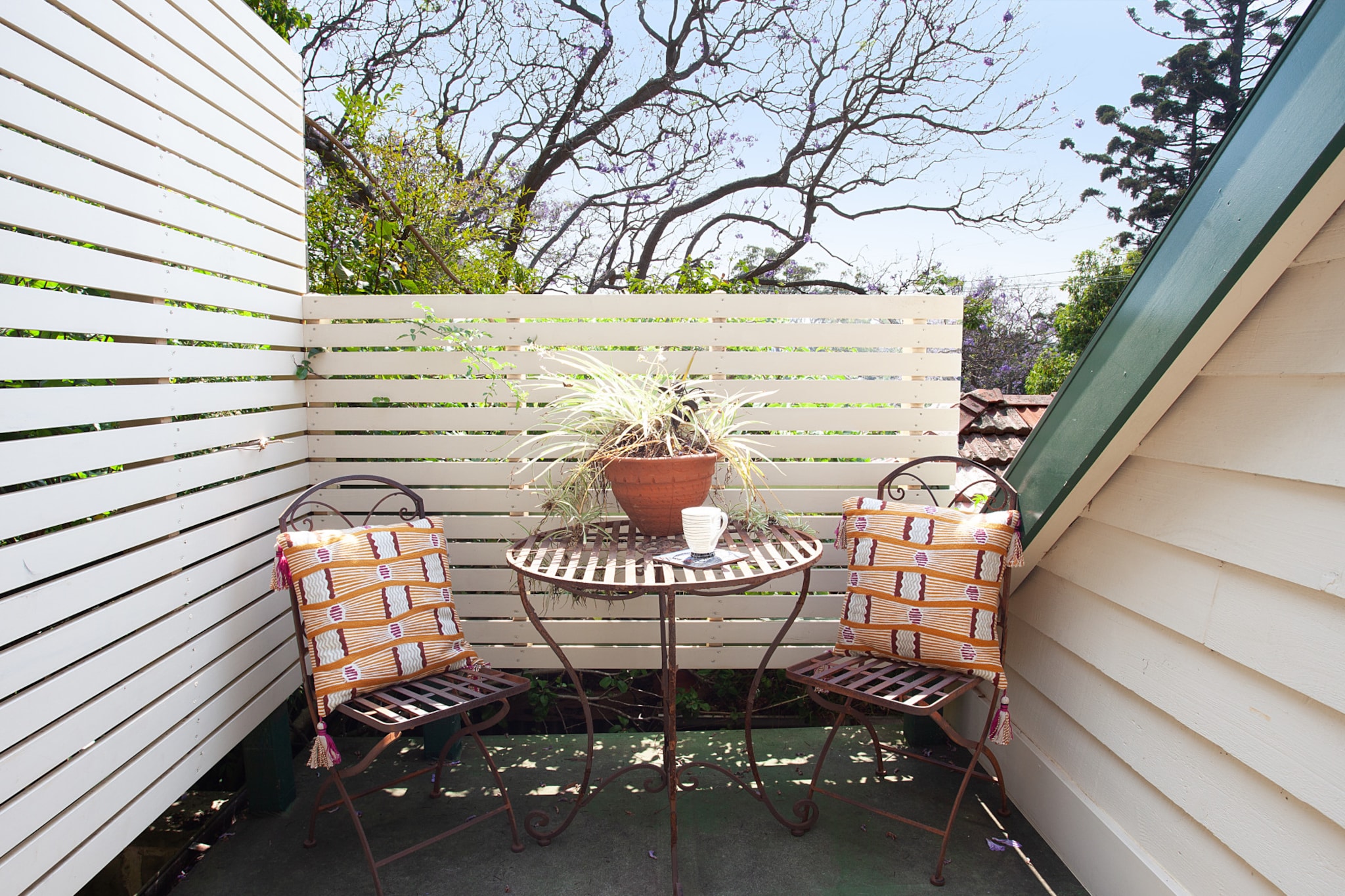 Property description
Nestled a block back from the water, surrounded by greenery, is a studio oasis with all the luxury comforts to feel like you’re in a private haven. Featuring a comfortable queen size bed, self-contained kitchen and secluded balcony, this is the ideal lower Sydney stay with the iconic Ferry only moments away. Ideally situated in an upmarket and leafy Sydney locale, you are only a short ferry trip from the main attractions of the city.
The space
This studio retreat has all the finishing touches to make you feel like you’re truly in a home away from home. Surrounded by luscious greenery and elevated to receive plenty of natural light, this stay offers the charm of Sydney’s lower north shore whilst feeling like you have your own private sanctuary to hide away in.
 
Featuring a queen size bed, recently renovated ensuite bathroom, mounted TV with oversized armchairs to watch from, dining for two and a desk for business travelers, this spacious studio has everything provided for. The kitchen includes an electric stove, toaster, kettle, coffee machine and dishwasher, with double french doors opening to a private balcony courtyard with al fresco dining.
 
The historic Woolwich area provides many self-guided walking trails that can be explored from your doorstep, as well as organised, guided tours providing you a more in depth guide to the area. Cockatoo Island is a listed UNESCO heritage site and just a 5 minute ferry ride across the water. It’s a perfect day trip, with many artists and cultural events often taking place during the warmer seasons.