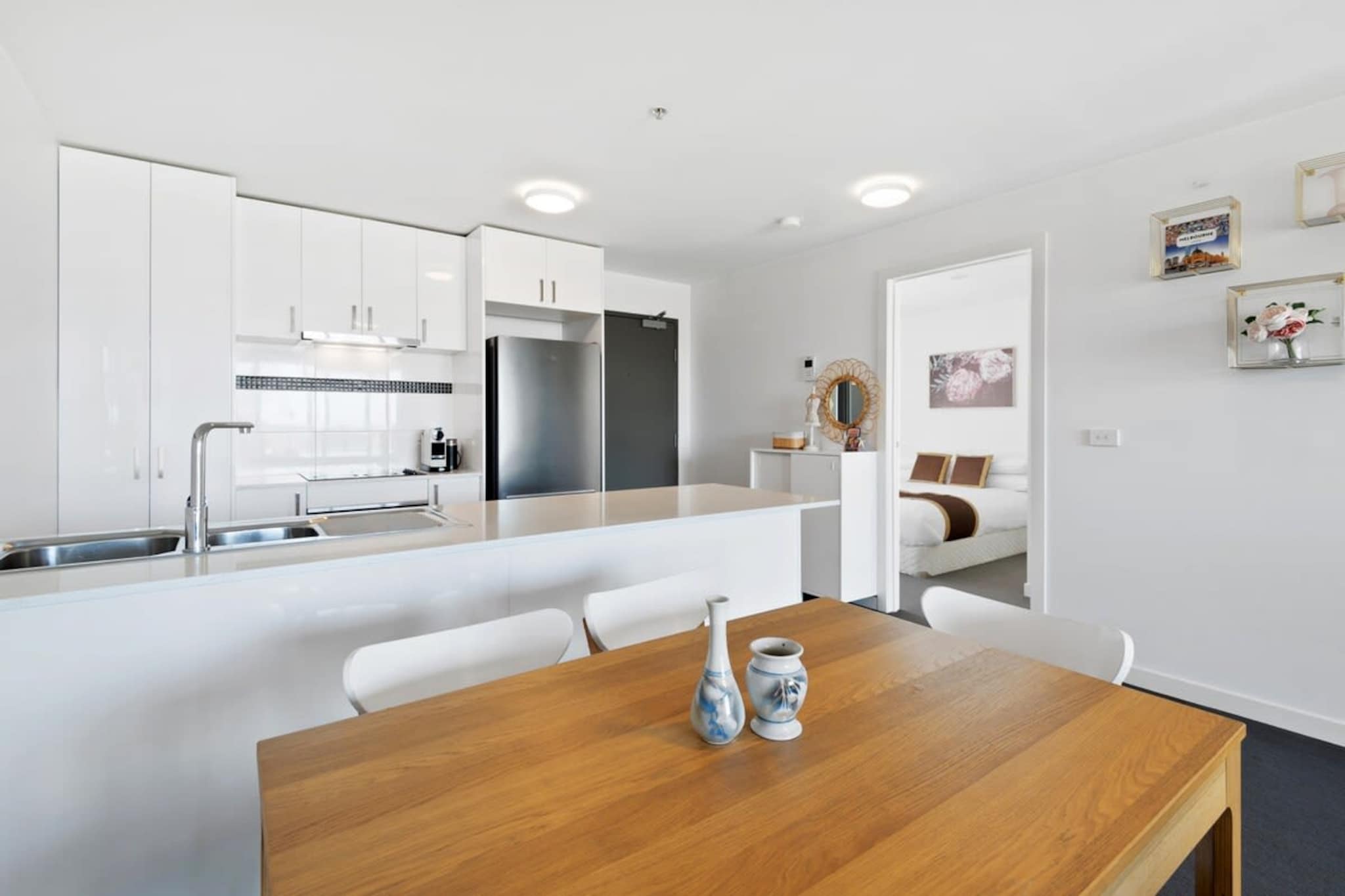 This spacious apartment is ideal for travellers looking for somewhere they can feel at home. With two bedrooms, large living areas and a spacious balcony, there’s plenty of space for you to feel comfortable. Located in Sunshine, it also makes a convenient base - you’re minutes away from local shops and restaurants, but you can also drive to CBD or attractions like Flemington Racecourse. The property is also easily accessible by public transport, only two minutes away from Sunshine station.

The space
This apartment feels airy and bright, thanks to the natural light coming from the private balcony and the open-plan layout of the living areas. The spaciousness of the living areas and balcony makes it perfect for both relaxing, working, or entertaining. The two bedrooms are large and comfortable, with one of the bedrooms featuring direct balcony access. The apartment is well-styled and sleek, with modern decor and furnishings throughout.
 
General
- Entire 2-bedroom, 1-bathroom apartment
- Private balcony with outdoor seating
- Air-conditioning and Heating are available
- Wi-Fi provided
 
Bedroom & bathroom
- Bedroom 1: 1x Queen bed with wardrobe space and balcony access
- Bedroom 2: 1x Double bed with wardrobe space
- Laundry facilities are available
 
Kitchen
- Modern appliances
- Toaster, kettle, coffee-maker and microwave available
- Oven and electric stovetop available
- Dishwasher available
 
Living room
- TV with free-to-air and streaming apps available
- Couch
- 4-seater dining table
Local area description
Discover the vibrant heart of Sunshine, a charming suburb where history and modernity blend seamlessly. Nestled within Melbourne's dynamic west, Sunshine boasts a rich tapestry of period and post-war homes, creating a picturesque residential area. The bustling town centre emerges as a key retail hub, offering an array of shopping experiences. For those seeking leisure and relaxation, the suburb's well-regarded pool facility provides a perfect escape. Cultural enthusiasts will revel in Sunshine's diverse culinary scene, a testament to its melting pot of cultures. With its proximity to the city, Sunshine offers both the tranquillity of suburban life and the convenience of urban living. Whether you're strolling through its peaceful streets or indulging in local delights, Sunshine promises a warm and welcoming experience for every visitor.
House rules
You are staying in a friendly and peaceful neighbourhood and we kindly ask you to respect the community and your surrounding neighbours. The following strict House Rules apply:
 
- No loud noise between 10 pm and 8 am
- No parties or antisocial behaviour
- No additional people are to access the property without our prior approval
- No pets are allowed in the property without approval
- No smoking is allowed at any times
- If you break something, please let us know
- To help protect all floor coverings do not wear any shoes inside the property
 
Please be aware that excessive noise such as amplified music, vocals or screaming or anti-social behaviour in the property or common areas can cause neighbours to complain to us, the Building Manager, Council Rangers or Police.
 
IMPORTANT: Any breach of the House Rules may lead to a $500 fine plus compensation for any cost/damage created and immediate eviction of the property.
 
Finally, when checking out, we kindly ask you for the following:
 
- Please leave all beds unmade
- Please clean up your dishes and put them away
- In case you have rearranged furniture, please put it back to the original location
- Please take out the rubbish and remember to use the right bins
- Please ensure all appliances, A/C and lights are off and doors and windows are closed
Interaction with guests
Welcome to MadeComfy! Our local team curates stays in exceptional Australian & New Zealand properties, ensuring style, comfort, and prime locations for discerning guests. We prioritise your needs to provide a memorable home-away-from-home experience. Explore our digital guidebooks for local recommendations, and don't hesitate to contact us throughout your stay. We're here to ensure your comfort – enjoy your stay with MadeComfy.
Notes
For your comfort, this property is prepared with professional-grade hotel-style linen, including a three-sheet setup, ensuring a fresh and hygienic sleep experience.
 
Extra Services:
- Early check-in: Our standard check-in is at 3 pm. To guarantee early access to the property we suggest booking the night before if available. Otherwise, early check-in is subject to availability from the night before at an additional cost.
- Late check-out: Our standard check-out is at 10 am. To guarantee a later check-out of the property we suggest booking an additional night if available. Otherwise, a late check-out is subject to availability from the night before to an additional cost.
- Baggage: For security reasons, we are unable to receive or to keep unattended baggage before check-in or after check-out
- We provide a small welcome amenity pack to get your stay started
 
 
Other things to note
- Please note Air conditioning and Heating are in the living area only.
- Unlimited on-street parking available at the Sunshine train station 3 mins. walking distance from the building.
- This booking is protected with coverage for lost baggage and emergency medical expenses, provided by Travel Support with claim upto 500 AUD (T&C Applies). For more details reach out to Guest Support team post booking.
Access description
You’ll have access to the entire property when you stay here, so it will feel like your own home.
Getting around
Public transport
The property is located a 2-minute walk from the Sunshine Train Station. There are also several bus stops located around the property.
 
Ride sharing
There are plenty of taxi and ride-saharing options available in Melbourne.
 
Points of Interest
- Sunshine Market Place – an 11-minute (850m) walk away
- Flemington Racecourse – a 12-minute (7.2 Km) drive away
- Melbourne CBD – a 22-minute (13.4 Km) drive away
 
Airport Access
- The property is approximately a 16-minute drive from Melbourne Airport.