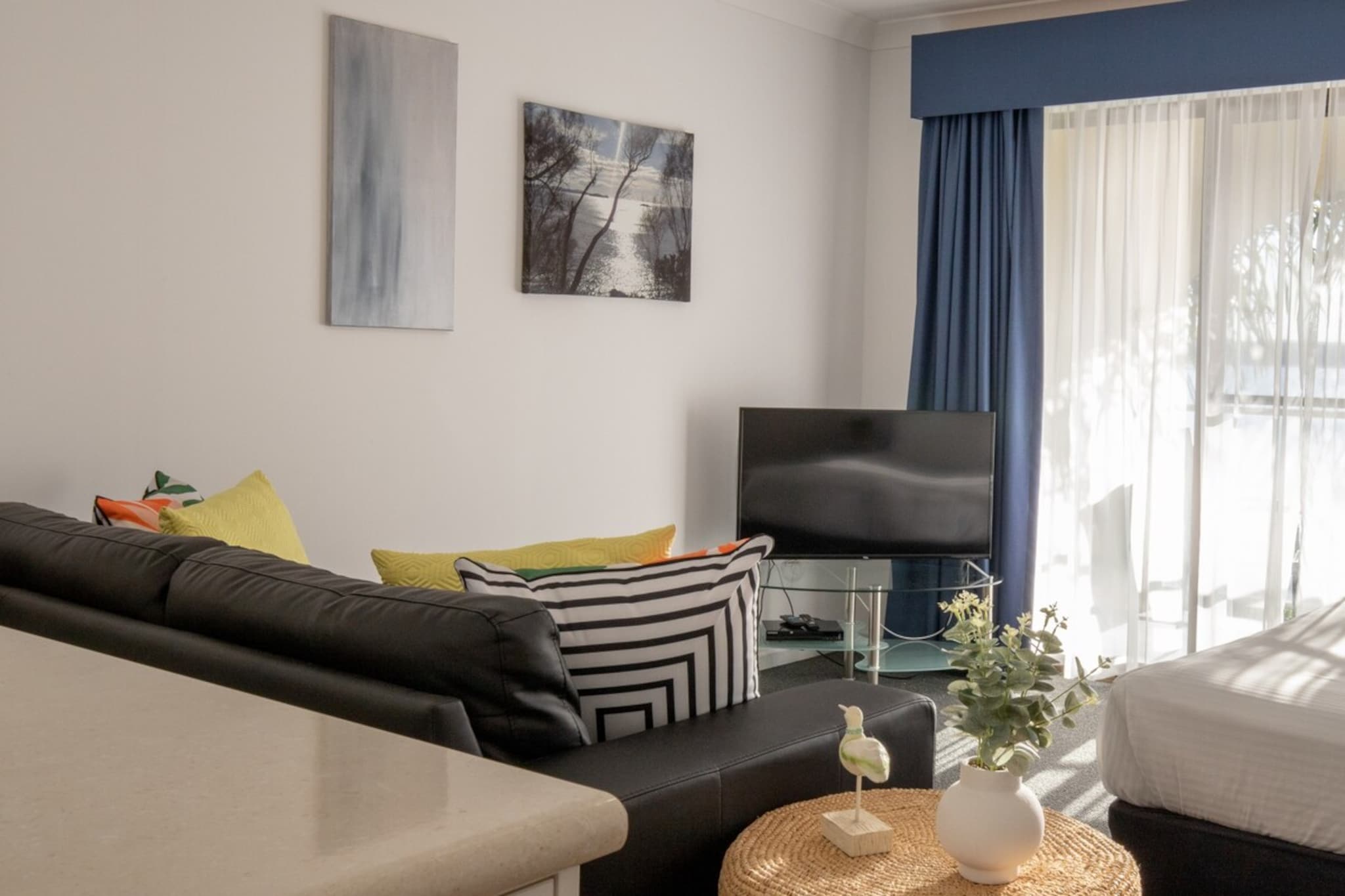 Explore the south coast of NSW in this chic studio that relaxes the senses and boasts a private veranda with a view over Caseys Beach. Freshly updated, this studio is fully appointed with a contemporary and minimal design that compliments the idyllic atmosphere of the coast. Ideal for a peaceful getaway, you won’t need to travel far to enjoy this escape with beaches and other attractions only minutes away and a BBQ area and pool on-site.
The space
This freshly renovated studio is located on the first floor of the property and features a private veranda with views overlooking Caseys Beach. Newly upgraded, this studio features a sleek, modern kitchen and living spaces with styling inspired by the beauty of the coastline, ensuring rest and relaxation.
 
General
- Spacious, newly-renovated 1-bedroom, 1-bathroom studio apartment
- Private balcony
- BBQ and swimming pool
- Air conditioning and heating are available
- Free Parking on premises
- Wi-Fi provided
- Self check-in
 
Bedroom & bathroom
- Bedroom 1: 1 x Queen Bed with direct balcony access
- 1 separate bathroom with heating
- Communal laundry facilities available (coin operated)
 
Kitchen
- Modern appliances
- Toaster and microwave available
- Oven and electric stovetop available
 
Living Room
- TV available with Free to Air Channels
- 3-seater couch
- 2-seater dining table
 
Points of Interest
Caseys Beach
Observation Point Lookout
Corrigans Beach
 
Getting there
Bateman’s Bay is a 4-hour drive from Sydney. Public transport is available via bus. Alternatively, direct flights (50 minutes) are available from Sydney to Moruya, where buses can take you directly to Beach Road.
Local area description
Batehaven is located in one of the south coast’s most beautiful towns, Batemans Bay. Batemans Bay is a destination that offers opportunities for nature-loving travellers to explore the coastline, ocean, wildlife and to indulge in local produce and fresh seafood. Batehaven is an excellent gateway to explore the greater Batemans Bay area and the perfect spot to relax for a day trip or getaway. Not only is this area of NSW’s south coast home to beautiful beaches and natural wonders, it also boasts a large range of eateries, restaurants and shopping options to ensure you have everything you need.
House rules
You are staying in a friendly and peaceful neighbourhood and we kindly ask you to respect the community and your surrounding neighbours. The following strict House Rules apply:
 
- No loud noise between 10 pm and 8 am
- No parties or antisocial behaviour
- No additional people are to access the property without our prior approval
- No pets are allowed in the property without approval
- No smoking is allowed at any times
- If you break something, please let us know
 
- To help protect all floor coverings do not wear any shoes inside the property
 
Please be aware that excessive noise such as amplified music, vocals or screaming or anti-social behaviour in the property or common areas can cause neighbours to complain to us, the Building Manager, Council Rangers or Police.
 
IMPORTANT: Any breach of the House Rules may lead to a $500 fine plus compensation for any cost/damage created and immediate eviction of the property.
 
Finally, when checking out, we kindly ask you for the following:
 
- Please leave all beds unmade
- Please clean up your dishes and put them away
- In case you have rearranged furniture, please put it back to the original location
- Please take out the rubbish and remember to use the right bins
- Please ensure all appliances, A/C and lights are off and doors and windows are closed
Interaction with guests
Welcome to MadeComfy! Our local team curates stays in exceptional Australian & New Zealand properties, ensuring style, comfort, and prime locations for discerning guests. We prioritise your needs to provide a memorable home-away-from-home experience. Explore our digital guidebooks for local recommendations, and don't hesitate to contact us throughout your stay. We're here to ensure your comfort – enjoy your stay with MadeComfy.
Notes
For your comfort, this property is prepared with professional-grade hotel-style linen, including a three-sheet setup, ensuring a fresh and hygienic sleep experience.
 
Extra Services:
- Early check-in: Our standard check-in is at 3 pm. To guarantee early access to the property we suggest booking the night before if available. Otherwise, early check-in is subject to availability from the night before at an additional cost.
- Late check-out: Our standard check-out is at 10 am. To guarantee a later check-out of the property we suggest booking an additional night if available. Otherwise, a late check-out is subject to availability from the night before to an additional cost.
- Baggage: For security reasons, we are unable to receive or to keep unattended baggage before check-in or after check-out
- We provide a small welcome amenity pack to get your stay started
 
Other things to note
- The washing machine is communal and coin-operated.
- AC and heater is not available in the bathroom
- There is a construction site next door that may contribute to noise levels.
- On-site parking for one car only. No space for boats or jet skis.
- There are no ride-sharing options in Batemans Bay and there is no train from Sydney to Batemans Bay
- This booking is protected with coverage for lost baggage and emergency medical expenses, provided by Travel Support with claim upto 500 AUD (T&C Applies). For more details reach out to Guest Support team post booking.
Access description
You can access the complex directly from Beach Road. After entering the complex, turn right. Go up the stairs on the right, at the top turn right and the unit is the first on the left.
 
There is a lockbox containing the keys next to the front door of the unit. We will send you the access code 2 days prior to your arrival through the booking portal.
 
You’ll have access to the entire property when you stay here, so it will feel like your own home.
Getting around
Public transport
There are bus stops located on Beach Road, a 2-minute walk from the property. These routes can take you to Canberra City via Batehaven’s Beach and Batemans Bay or to Moruya via Denhams Beach, Surf Beach and Broulee.
 
Ride sharing
There are plenty of taxi and ride-sharing options readily available throughout Batemans Bay. We recommend booking a taxi in advance as there may be limited availability.
 
Points of Interest
 
Caseys Beach
Observation Point Lookout
Corrigans Beach
 
Getting there
Bateman’s Bay is a 4-hour drive from Sydney. Public transport is available via train and bus. Alternatively, direct flights (50 minutes) are available from Sydney to Moruya, where buses can take you directly to Beach Road.