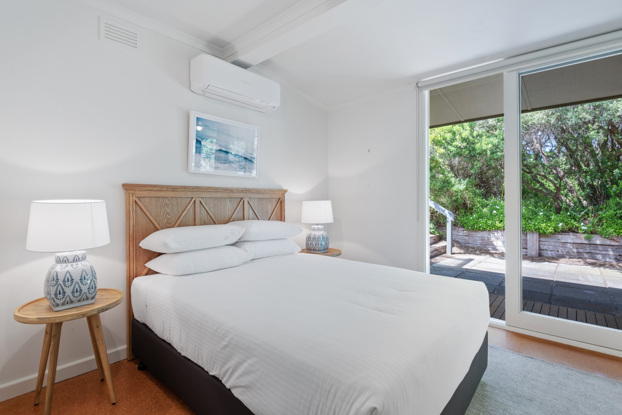 Engross in the iconic Mornington Peninsula with this idyllic 4-bed house situated near the beach and national park in Sorrento. Featuring a generous home with an abundance of natural light, deck space with outdoor seating and an alfresco dining area, this sleek property has a truly timeless quality. Located a short distance from town and shops this property offers prime access to all the local natural and shopping attractions. Perfect for a seaside holiday away, this is the property for you.
The space
Gorgeously designed this mid-century inspired modern bungalow offers chic decor and an open feel accentuated by the abundance of natural light. Featuring an open plan living area, an additional lounge room, a fully stocked kitchen, modest bathrooms, comfy bedrooms, a pristine garden, bedroom deck space with outdoor seating and an alfresco dining area with a BBQ. This home offers the perfect summer or winter retreat situated by nature and the beach.
 
General
- Incredible 4-bedroom, 2-bathroom house
- On-site parking is available
- Wifi is available
- Air conditioning and heating available in all rooms
- Generous deck space including outdoor seating
- Gorgeous alfresco dining area with a BBQ available
- Beautifully refined interiors with chic homely decor
- Great location a short distance from the beach, general store and national park
 
Bedroom & Bathroom
- Bedroom 1: 1x Queen Bed
- Bedroom 2: 1x Queen Bed
- Bedroom 3: 1x Double Bed
- Bedroom 4: 2x Single Beds
- Sleek modern bathrooms
- Travel essentials, towels and hairdryer provided
- Laundry room available with washing machine and dryer
 
Kitchen
- Fully stocked with modern appliances
- Toaster, kettle, coffee machine and microwave available
- Oven and gas stove top available
- Dishwasher available
- 2-seater countertop area
 
Living Room
- Plush couches and armchairs with a coffee table available
- TVs with free-to-air and streaming options available
- 8-seater dining table available