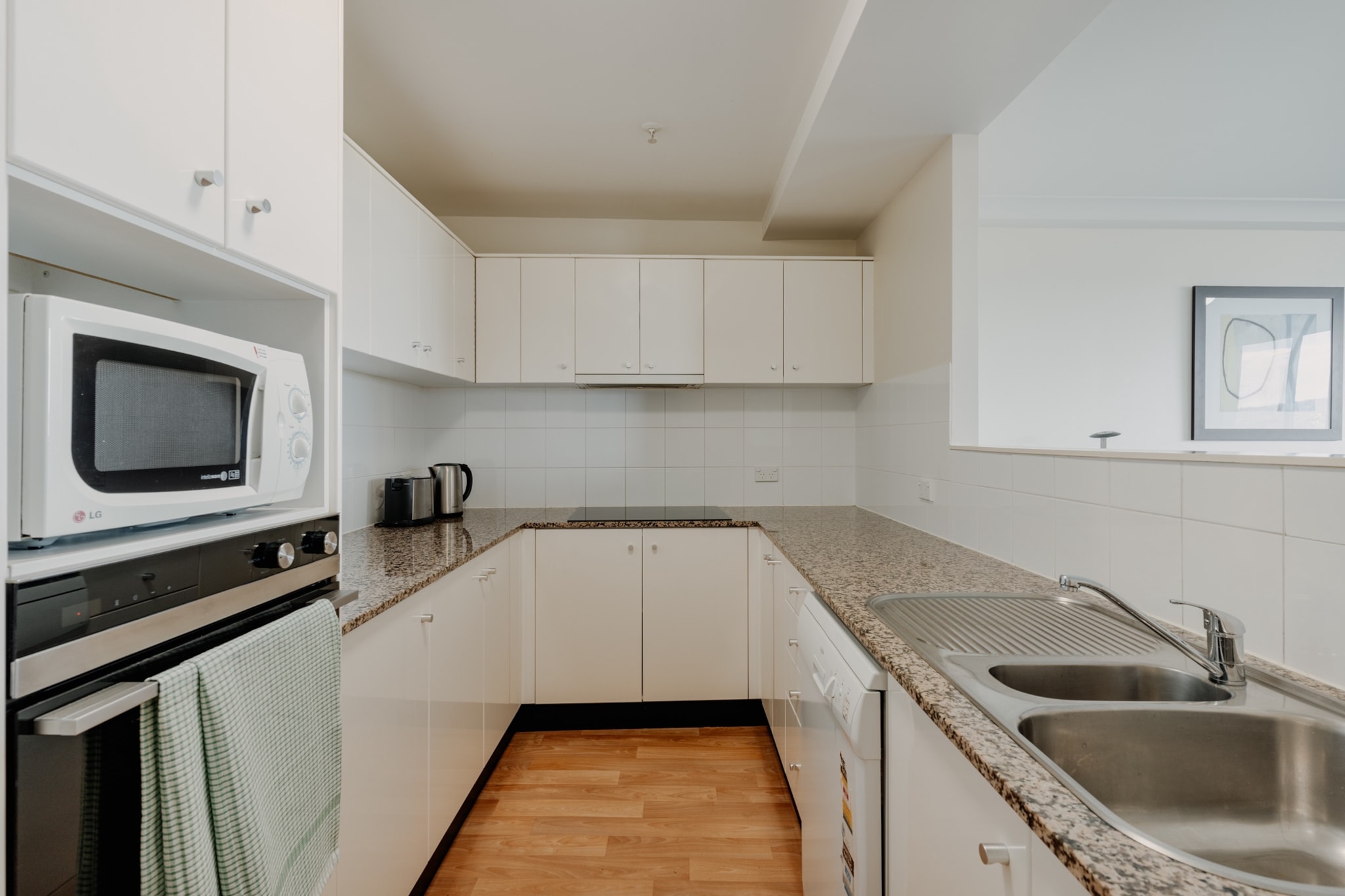 Conveniently located in the heart of Canberra, this two-bedroom apartment is perfectly suited for those looking to stay close to the action – with food, shops, bars and nightlife, cultural sights, theatres, galleries and public transport are at your doorstep. You’ll have full access to the entire apartment, featuring secure parking and luxury building amenities including a gym and BBQ area.
The space
This property offers an open living plan design with one of the best views of Lake Burley Griffith. Featuring a cosy feel, two bathrooms, a fully stocked kitchen, modern appliances, and gym access, this apartment is a fully-equipped stay.
 
General
- Entire 2 bedroom apartment with 2 bathrooms
- Air conditioning and heating throughout the property
- Wi-Fi is available
- Balcony with stunning lake views
- On-site parking space for 2
- Laundry facilities - washer and dryer
- Gym, tennis court and BBQ access
- Self check-in
 
Bedroom
- Bedroom 1: 1x Double Bed
- Bedroom 2: 1x Queen bed
- Blackout blinds in both bedrooms
 
Bathroom
- Spacious bathrooms with shower
- Travel essentials, towels and hairdryer provided
 
Kitchen
- Well-stocked kitchen with utensils for cooking own meals
- Appliances including oven, gas stovetop and dishwasher
- Toaster, kettle, coffee machine and microwave available
 
Living / Dining Room
- Comfortable lounge and dining area for 6
- Smart TV with free to air and streaming options
 
Points of Interest
- 13 min wak, 6 min drive to National Capital Exhibition and Commonwealth Park
- 16 min walk, 4 min drive to Canberra Centre
- 37 min walk, 9 min drive to Capital Hill
- 14 min drive to Canberra Centre
Local area description
Canberra the suburb is famously the commercial centre of Australia’s capital city. Known for its numerous shops, cafes, restaurants and entertainment facilities, Canberra is the central suburb to explore the rest of the city. With ample amounts of public transport and loads of nearby parking, you won’t have to go far to find attractions for everyone. Home to the Canberra Museum, Canberra Centre, Canberra Theatre Centre and National Convention Centre, there's always something on to keep visitors busy.
House rules
You are staying in a friendly and peaceful neighbourhood and we kindly ask you to respect the community and your surrounding neighbours. The following strict House Rules apply:
- No loud noise between 10 pm and 8 am
- No parties or antisocial behaviour
- No additional people are to access the property without our prior approval
- No pets are allowed in the property without approval
- No smoking is allowed at any times
- If you break something, please let us know
 
- To help protect all floor coverings do not wear any shoes inside the property
 
Please be aware that excessive noise such as amplified music, vocals or screaming or anti-social behaviour in the property or common areas can cause neighbours to complain to us, the Building Manager, Council Rangers or Police.
 
IMPORTANT: Any breach of the House Rules may lead to a $500 fine plus compensation for any cost/damage created and immediate eviction of the property.
 
Finally, when checking out, we kindly ask you for the following:
- Please leave all beds unmade
- Please clean up your dishes and put them away
- In case you have rearranged furniture, please put it back to the original location
- Please take out the rubbish and remember to use the right bins
- Please ensure all appliances, A/C and lights are off and doors and windows are closed
Interaction with guests
Welcome to MadeComfy! Our local team curates stays in exceptional Australian & New Zealand properties, ensuring style, comfort, and prime locations for discerning guests. We prioritise your needs to provide a memorable home-away-from-home experience. Explore our digital guidebooks for local recommendations, and don't hesitate to contact us throughout your stay. We're here to ensure your comfort – enjoy your stay with MadeComfy.
Notes
- For your comfort, this property is prepared with professional-grade hotel-style linen, including a three-sheet setup, ensuring a fresh and hygienic sleep experience.
-Please keep noise level to a minimum between 10pm and 8am for neighbours. Excessive noise could lead to an on-the-spot AUD500 fine and/or eviction from the property.
 
Extra Services:
- Early check-in: Our standard check-in is at 3 pm. To guarantee early access to the property we suggest booking the night before if available. Otherwise, early check-in is subject to availability from the night before at an additional cost.
- Late check-out: Our standard check-out is at 10 am. To guarantee a later check-out of the property we suggest booking an additional night if available. Otherwise, a late check-out is subject to availability from the night before to an additional cost.
- Baggage: For security reasons, we are unable to receive or to keep unattended baggage before check-in or after check-out
- We provide a small welcome amenity pack to get your stay started
- This booking is protected with coverage for lost baggage and emergency medical expenses, provided by Travel Support with claim upto 500 AUD (T&C Applies). For more details reach out to Guest Support team post booking.
Access description
You’ll have access to the entire property when you stay here, so it will feel like your own home.
- The key collection is located offsite, 1 km away from the property, and it is not available 24/7. Further details will be provided 3 days before check-in if your booking is successfully reserved.
Getting around
Public transport
Check out the TripGo app for transport timetables.
 
Ride sharing
We highly recommend using ride-sharing services: For first time users, download the Uber app for more information.
 
Points of Interest
- 13 min wak, 6 min drive to National Capital Exhibition and Commonwealth Park
- 16 min walk, 4 min drive to Canberra Centre
- 37 min walk, 9 min drive to Capital Hill
- 14 min drive to Canberra Centre
 
Getting there
The property is approximately a 14-minute drive from Canberra Airport.