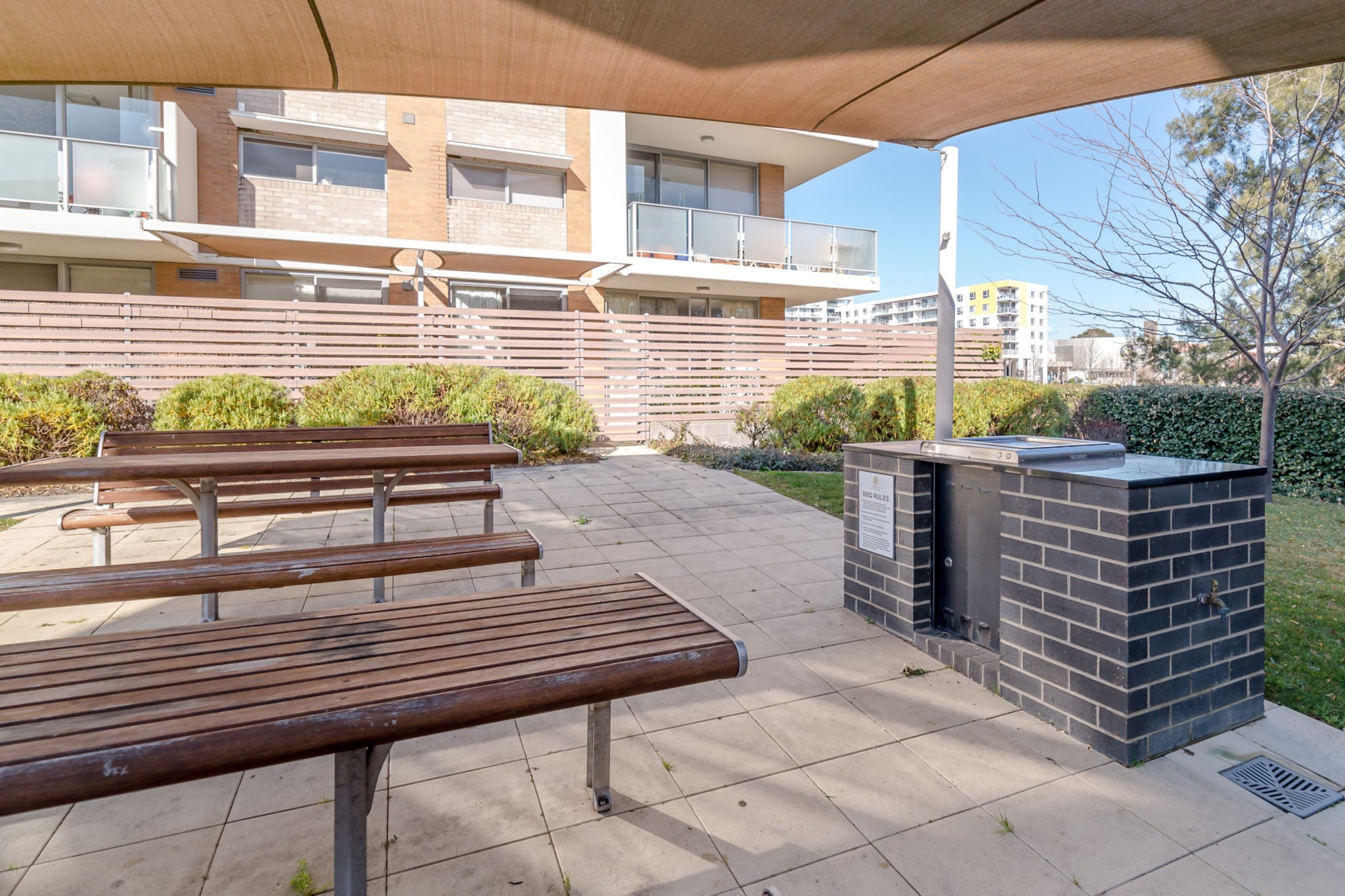 Explore the bustling atmosphere of Philip in this sleek and modern 1-bed apartment situated steps from bustling shops. This beautiful apartment offers the perfect escape for a single or a couple, featuring a cosy layout and a private courtyard. Situated near numerous local restaurants, bars and cafes, the property also boasts an on-site pool and a communal BBQ area to enjoy. Being only a short drive from the city's centre, experience the peaceful yet vibrant Philip life.
The space
This chic property is cosy and modern and offers an open living plan design with abundant natural light and a private courtyard. Featuring a cosy feel, a sleek bathroom, a fully stocked kitchen, modern appliances, charming decor, and a private courtyard accessible from the living or bedroom, this property is an idyllic suburban getaway.
 
General
- Chic 1-bedroom, 1-bathroom apartment.
- Close to public transport.
- Wi-Fi is provided.
- Air conditioner and heating available
- Private courtyard with outdoor seating.
- Communal BBQ and Pool facilities.
- Located minutes from shops, cafes, restaurants and transport interchange
- Self check-in
 
Bedroom & bathroom
- Bedroom 1: 1x Queen Bed with courtyard access.
- Sleek main bathroom.
- Laundry unit available - washer and dryer.
 
Kitchen
- Fully stocked with appliances.
- Kettle, toaster, coffee machine and microwave available
- Oven and electric stovetop available.
- Dishwasher available.
 
Living Room
- Couch and armchair available.
- Smart TV with free-to-air and streaming options available.
- 2-seater dining table.
 
Points of Interest
- Westfield Woden and Town Centre - 7 minutes (550m) walk away.
- Canberra Hospital - 5 minutes (1.9km) drive away.
- Philip Enclosed Oval and Woden Athletic Park - 8 minutes (850m) walk away.
Local area description
Phillip is a snug Canberra suburb located outside the city centre, in the Woden Valley district. Home to the Woden Town Centre, the suburb is a hub of activity, situated at the intersection of major arterial roads. The suburb contains numerous distinct areas and is only 5 minutes away from the Canberra Hospital. From the bustling commercial park, Westfield Woden shops and the town centre clustered on the eastern side of the suburb. The leafier northwestern side features numerous parks, ovals and a public pool, there’s always activity happening. With quaint suburban streets, nestled not far from the livelier areas, find a calm refuge, in this leafy Canberra suburb.
House rules
You are staying in a friendly and peaceful neighbourhood and we kindly ask you to respect the community and your surrounding neighbours. The following strict House Rules apply:
- No loud noise between 10 pm and 8 am
- No parties or antisocial behaviour
- No additional people are to access the property without our prior approval
- No pets are allowed in the property without approval
- No smoking is allowed at any times
- If you break something, please let us know
 
Please be aware that excessive noise such as amplified music, vocals or screaming or anti-social behaviour in the property or common areas can cause neighbours to complain to us, the Building Manager, Council Rangers or Police.
 
IMPORTANT: Any breach of the House Rules may lead to a $500 fine plus compensation for any cost/damage created and immediate eviction of the property.
 
Finally, when checking out, we kindly ask you for the following:
- Please leave all beds unmade
- Please clean up your dishes and put them away
- In case you have rearranged furniture, please put it back to the original location
- Please take out the rubbish and remember to use the right bins
- Please ensure all appliances, A/C and lights are off and doors and windows are closed
Interaction with guests
Welcome to MadeComfy! Our local team curates stays in exceptional Australian & New Zealand properties, ensuring style, comfort, and prime locations for discerning guests. We prioritise your needs to provide a memorable home-away-from-home experience. Explore our digital guidebooks for local recommendations, and don't hesitate to contact us throughout your stay. We're here to ensure your comfort – enjoy your stay with MadeComfy.
Notes
- For your comfort, this property is prepared with professional-grade hotel-style linen, including a three-sheet setup, ensuring a fresh and hygienic sleep experience.
- The name of the Apartments are Avoca Apartments. The property is in building K.
- The underground car park is available. The access is from Surprise Pl.
- Located minutes from shops, cafes, restaurants and transport interchange.
- Please keep the noise level to a minimum between 10 pm and 8 am for neighbours. Excessive noise could lead to an on-the-spot AUD500 fine and/or eviction from the property.
 
Extra Services:
- Early check-in: Our standard check-in is at 3 pm. To guarantee early access to the property we suggest booking the night before if available. Otherwise, early check-in is subject to availability from the night before at an additional cost.
- Late check-out: Our standard check-out is at 10 am. To guarantee a later check-out of the property we suggest booking an additional night if available. Otherwise, a late check-out is subject to availability from the night before to an additional cost.
- Baggage: For security reasons, we are unable to receive or to keep unattended baggage before check-in or after check-out
- We provide a small welcome amenity pack to get your stay started
- Cleaning services are available during your stay for an additional cost. Inform us and we'll organise it for you
- This booking is protected with coverage for lost baggage and emergency medical expenses, provided by Travel Support with claim upto 500 AUD (T&C Applies). For more details reach out to Guest Support team post booking.
Access description
From Easty St, turn right to Guardian St and locate the property is situated in the back building. You’ll have access to the entire property when you stay here, so it will feel like your own home.
- There is a lockbox containing the keys of the property in it. We will send you the access code 3 days prior to your arrival through the booking portal.
Getting around
Public transport
The property is located 650m from the Woden Interchange, operating bus routes to City, City West, AMC loop, Tuggeranong, Cooleman Court, Yass and Queanbeyan.
 
Ride sharing
There is plenty of taxi and ride-sharing options readily available throughout Canberra.
 
Points of Interest
Westfield Woden and Town Centre - 7 minutes (550m) walk away.
Philip Enclosed Oval and Woden Athletic Park - 8 minutes (850m) walk away.
Canberra Hospital - 5 minutes (1.9km) drive away.
 
Getting there
The property is approximately a 14-minute drive from Canberra Airport.