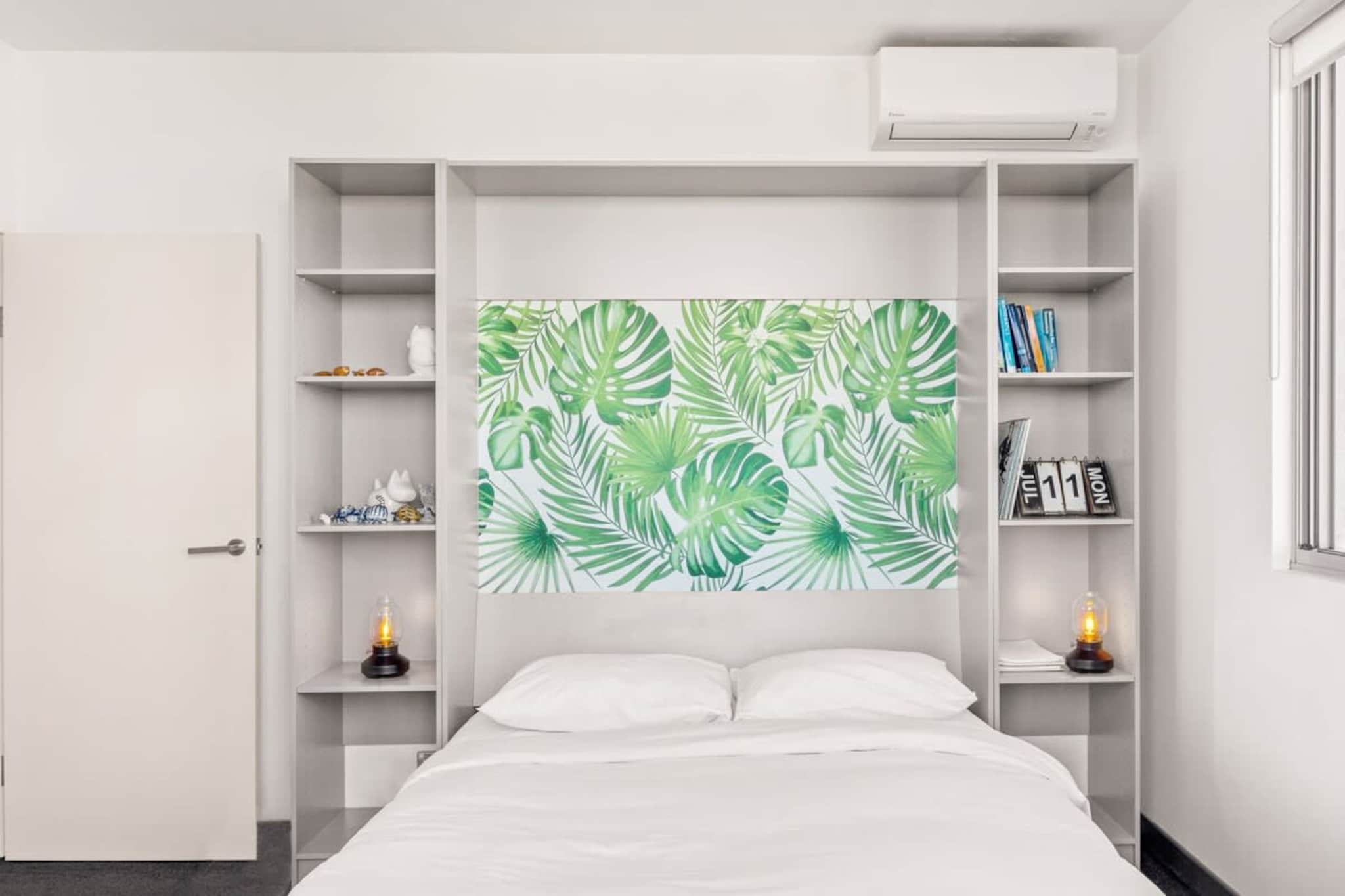 Immerse yourself in the bustling atmosphere of Alexandria in this spacious 2-bed unit with two balconies that offers expansive views. Situated minutes from parks, shops and Green Square, explore all the local scenes. Indulge in the thriving cafe, restaurant and bar scenes that are mere steps away. With its spacious design and modern decor, this incredible property is the perfect destination for those looking to experience all that Sydney's inner city has to offer.
The space
Impeccably designed, this modern apartment offers a spacious open living plan and charming decor to help you settle right in. Featuring a spacious living room, two bedrooms, dedicated work desk, elegant bathrooms, a sleek kitchen, modern appliances and two spacious balconies with outdoor seating and a BBQ. This property offers a truly unbeatable design.
 
General
- Comfortable 2-bedroom, 2-bathroom apartment.
- WI-FI available.
- Street parking available.
- Air conditioning and heating available.
- Private living room balcony with outdoor dining and BBQ available.
- Spacious shared bedroom balcony with expansive views and outdoor seating.
 
Bedroom & bathroom
- Bedroom 1: 1x Queen Bed with balcony access and ensuite.
- Bedroom 2: 1x Queen Bed with a study desk and balcony access.
- Sleek modern bathrooms.
- Laundry room available - Washer and dryer.
 
Kitchen
- Fully stocked kitchen with appliances, cookware and utensils.
- Kettle, toaster, coffee machine and microwave available
- Oven and gas stovetop available.
- Dishwasher available.
 
Living Room
- Plush couch and armchair available.
- Smart TV with free-to-air and streaming options available.
- 4-seater dining table.
 
Points of Interest
- IGA Alexandria– 1 minute (100m) walk away
- Alexandria Park - 4 minutes (300m) walk away.
- Green Square Shops, Library and Station - 6 minutes (500m) walk away
- 10 minute walk from the vibrant neighbourhood of Redfern.
- Close by to Waterloo, with many restaurants and coffee shops.
 
Getting there
The property is approximately a 14-minute drive away from Sydney’s CBD or a 10-minute drive away from Canberra’s CBD.
Local area description
Alexandria is a popular Sydney inner-city suburb known for its rejuvenated and hip image. Formerly an industrial precinct Alexandria has in recent decades graduated to a thriving residential suburb, full of elegantly modern apartment blocks. Famous for being a hub of cafe and dining culture, the suburb is home to the popularly The Grounds of Alexandria as well as numerous pubs and the bustling Archie Brothers Arcade. The suburb also offers extensive walks and parkland to explore, hosting both Alexandria and Sydney Parks. Bustling with an energetically modern heart, this popular suburb is the place to be.
House rules
You are staying in a friendly and peaceful neighbourhood and we kindly ask you to respect the community and your surrounding neighbours. The following strict House Rules apply:
 
- No loud noise between 10 pm and 8 am
- No parties or antisocial behaviour
- No additional people are to access the property without our prior approval
- No pets are allowed in the property without approval
- No smoking is allowed at any times
- If you break something, please let us know
- To help protect all floor coverings do not wear any shoes inside the property
 
Please be aware that excessive noise such as amplified music, vocals or screaming or anti-social behaviour in the property or common areas can cause neighbours to complain to us, the Building Manager, Council Rangers or Police.
 
IMPORTANT: Any breach of the House Rules may lead to a $500 fine plus compensation for any cost/damage created and immediate eviction of the property.
 
Finally, when checking out, we kindly ask you for the following:
 
- Please leave all beds unmade
- Please clean up your dishes and put them away
- In case you have rearranged furniture, please put it back to the original location
- Please take out the rubbish and remember to use the right bins
- Please ensure all appliances, A/C and lights are off and doors and windows are closed
Interaction with guests
Welcome to MadeComfy! Our local team curates stays in exceptional Australian & New Zealand properties, ensuring style, comfort, and prime locations for discerning guests. We prioritise your needs to provide a memorable home-away-from-home experience. Explore our digital guidebooks for local recommendations, and don't hesitate to contact us throughout your stay. We're here to ensure your comfort – enjoy your stay with MadeComfy.
Notes
For your comfort, this property is prepared with professional-grade hotel-style linen, including a three-sheet setup, ensuring a fresh and hygienic sleep experience.
 
Other things to note:
- Please note, there is no dedicated parking and there is street parking available only (free and paid).
 
- Extra Services:
- Early check-in: Our standard check-in is at 3 pm. To guarantee early access to the property we suggest booking the night before if available. Otherwise, early check-in is subject to availability from the night before at an additional cost.
- Late check-out: Our standard check-out is at 10 am. To guarantee a later check-out of the property we suggest booking an additional night if available. Otherwise, a late check-out is subject to availability from the night before to an additional cost.
- Baggage: For security reasons, we are unable to receive or to keep unattended baggage before check-in or after check-out
- We provide a small welcome amenity pack to get your stay started
- This booking is protected with coverage for lost baggage and emergency medical expenses, provided by Travel Support with claim upto 500 AUD (T&C Applies). For more details reach out to Guest Support team post booking.
-Some of the parking spaces are quite narrow and had reports of minor vehicle scratches.
A gentle reminder to guests to take extra care when parking and moving around the carpark, and to be mindful when opening car doors to avoid contact with neighboring vehicles.
Access description
You’ll have access to the entire property when you stay here, so it will feel like your own home.
Getting around
Public transport
The property is located within walking distance of numerous bus stops namely on Botany Rd and McEvoy St which operate trips to MAscot, Port Botany Depot, Redfern Station, Eastlakes Racecourse Pl, Coogee Beach, Bondi Junction, Glebe Point, Stamford Hotel and Marrickville Metro. Additionally, the nearby Green Square train station operates along to T8 line to City, Macarthur via Airport or Sydenham.
 
Ride sharing
There are plenty of taxi and ride-sharing options readily available throughout Sydney.
 
Points of Interest
- IGA Alexandria– 1 minute (100m) walk away
- Alexandria Park - 4 minutes (300m) walk away.
- Green Square Shops, Library and Station - 6 minutes (500m) walk away.
- 10 minute walk from the vibrant neighbourhood of Redfern.
- Close by to Waterloo, with many restaurants and coffee shops.
 
Getting there
The property is approximately a 14-minute drive away from Sydney’s CBD or a 10-minute drive away from Canberra’s CBD.