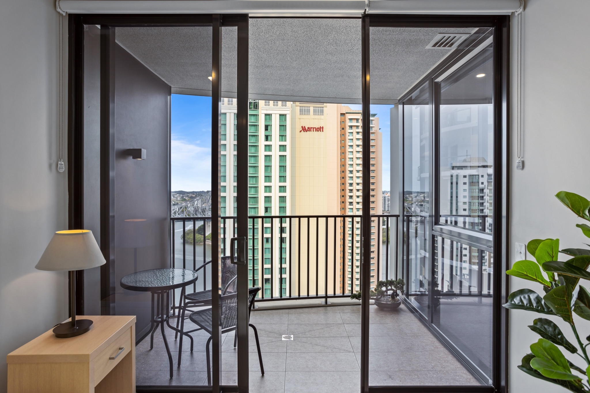 Explore the vibrant atmosphere of Brisbane in this cosy 1-bed apartment with stunning river views. Featuring a snug design this modern property offers an on-site pool, gym and communal BBQ facilities. Situated in the heart of the city the property is located within walking distance of cafes, shops, restaurants, bars and the Howard Smith Wharves. With a private balcony and outdoor seating, this property is the perfect escape for couples wanting to explore the city.
The space
Elegantly designed this modern apartment offers a quaint and relaxing property to reside. With its chic open living plan, sleek kitchen, modern appliances, polished kitchen, comfortable bedroom, stunning views and balcony with outdoor seating. This property is a perfect city base.
 
General
- Chic 1-bedroom, 1-bathroom apartment
- Wi-Fi is provided
- Air conditioner and heater
- Private balcony with outdoor seating
- On-site pool, gym and a communal BBQ area available for use
 
Bedroom & bathroom
- Bedroom 1: 1x Queen Bed with blackout blinds
- Sleek modern bathroom
- Laundry unit with washer and dryer
- Travel essentials, towels and hairdryer provided
 
Kitchen
- Fully stocked with cookware, utensils and cutlery
- Kettle, toaster, coffee machine and microwave
- Oven and electric stovetop
- Dishwasher available
 
Living Room
- TV with free-to-air and streaming options
- Plush couch, armchair and coffee table
- 2-seater dining table
 
Points of Interest
Centenary Place Park - 2 minutes (210m) walk away
Spring Hill Marketplace Shopping Centre - 3 minutes (230m) walk away
Howard Smith Wharves - 6 minutes (500m) walk away