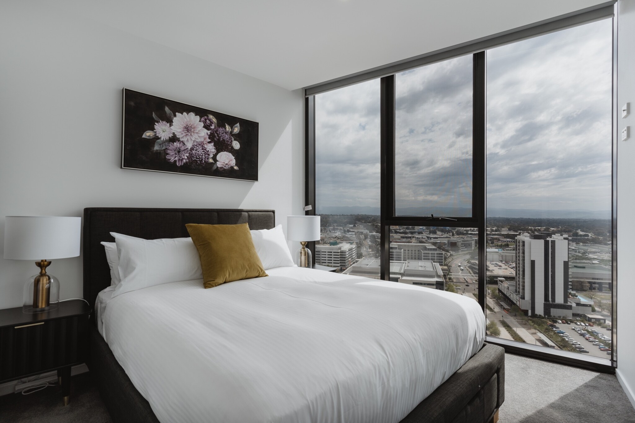 Engross yourself in Canberran life in this beautiful 2-bed apartment with stunning views of Lake Ginninderra. With a sleek modern design, the property boasts a private balcony with outdoor seating and views. Situated above shops and cafes, the property is nearby the local Westfield which offers an array of shopping and dining options to explore. Located by both UC and the Lake foreshore parklands, this pristine apartment is perfect for those looking for a convenient and elegant property.