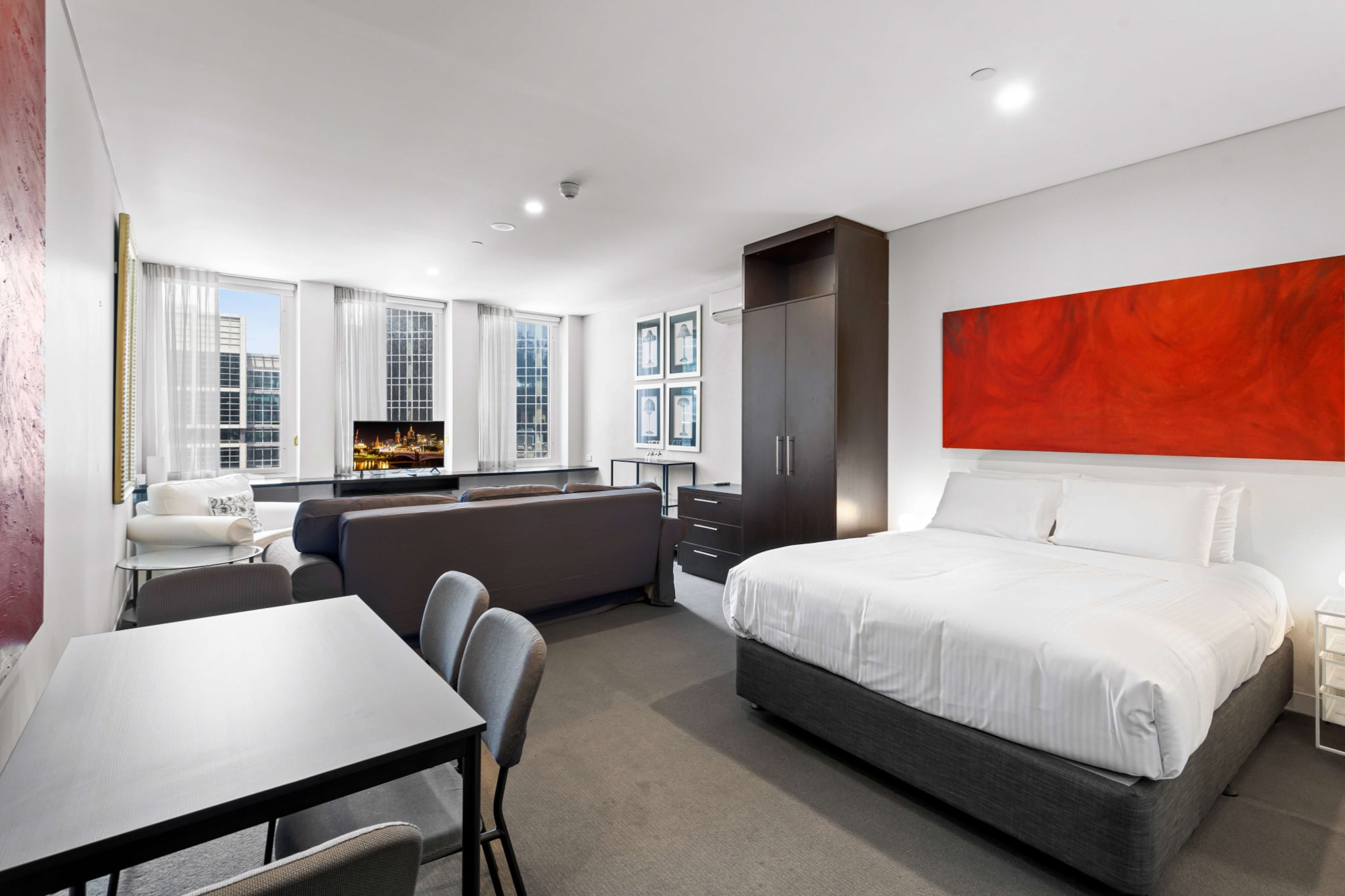 Discover the beating heart of Melbourne in this cosy studio apartment in the city’s centre. Featuring a contemporary open-plan design, this sleek apartment offers refined elegance in a charming property. Situated within walking distance of the city's most popular cafes, restaurants, bars, theatres, attractions and stadiums, this gorgeous property offers an unbeatable gateway to everything the city has to offer. Perfect for those seeking an adventure, this is the place for you.

The space
Gorgeously designed, this bright apartment features chic decor that’s accentuated by an abundance of natural light and a beautiful view. Featuring an open-plan design, an elegant kitchen, modern appliances, a sleek bathroom, a generous bed, and an additional sofa bed. Relish in this property's incredible location perfect for exploring the city.
 
General
- Chic studio apartment with 1 bathroom
- Wi-Fi available
- Close to public transport
- Living room air conditioning
- Contemporary interiors with chic decor and furnishings
- Incredible location moments from numerous shops, venues and attractions
 
Living Room
- 1x Queen Bed
- Additional queen sofa bed available
- Plush couch, armchair and coffee table
- TV with free-to-air and streaming options available
- 4-seater dining table
- Air conditioning
 
Kitchen
- Fully equipped with cookware, utensils and cutlery
- Toaster, kettle, coffee machine and microwave
- Oven and electric stovetop
- Dishwasher
 
Bathroom
- Sleek bathroom
- Travel essentials, towels and hairdryer provided
 
Laundry
- Coin-operated common laundry.
Local area description
Melbourne CBD is the bustling heart of this famous artistic Australian metropolis. Being home to some of Melbourne's most iconic sites such as the Flinders Street Station and Federation Square, the city is always bursting at the seams with things to do. Home to a thriving cafe and restaurant culture, dive right into the culinary mastery of the local business. Go shopping in the myriad of famous, fashionable or even boutique stores. Only a short tram ride away from all the hip inner-city suburbs or the picturesque Port Phillip bayside, Melbourne CBD is the destination for a trip to this sprawling city.
House rules
You are staying in a friendly and peaceful neighbourhood and we kindly ask you to respect the community and your surrounding neighbours. The following strict House Rules apply:
 
- No loud noise between 10 pm and 8 am
- No parties or antisocial behaviour
- No additional people are to access the property without our prior approval
- No pets are allowed in the property without approval
- No smoking is allowed at any times
- If you break something, please let us know
- To help protect all floor coverings do not wear any shoes inside the property
 
Please be aware that excessive noise such as amplified music, vocals or screaming or anti-social behaviour in the property or common areas can cause neighbours to complain to us, the Building Manager, Council Rangers or Police.
 
IMPORTANT: Any breach of the House Rules may lead to a $500 fine plus compensation for any cost/damage created and immediate eviction of the property.
 
Finally, when checking out, we kindly ask you for the following:
 
- Please leave all beds unmade
- Please clean up your dishes and put them away
- In case you have rearranged furniture, please put it back to the original location
- Please take out the rubbish and remember to use the right bins
- Please ensure all appliances, A/C and lights are off and doors and windows are closed
Interaction with guests
Welcome to MadeComfy! Our local team curates stays in exceptional Australian & New Zealand properties, ensuring style, comfort, and prime locations for discerning guests. We prioritise your needs to provide a memorable home-away-from-home experience. Explore our digital guidebooks for local recommendations, and don't hesitate to contact us throughout your stay. We're here to ensure your comfort – enjoy your stay with MadeComfy.
Notes
- For your comfort, this property is prepared with professional-grade hotel-style linen, including a three-sheet setup, ensuring a fresh and hygienic sleep experience.
- There is no on-site parking available.
- There are no stairs on the property. Wheelchair accessible.
- There is a common laundry on level 14. The washing machine and dryer are coin-operated.
- The vacuum cleaner is located in the laundry area. The use of vacuum cleaners is free.
 
Extra Services:
- Early check-in: Our standard check-in is at 3 pm. To guarantee early access to the property we suggest booking the night before if available. Otherwise, early check-in is subject to availability from the night before at an additional cost.
- Late check-out: Our standard check-out is at 10 am. To guarantee a later check-out of the property we suggest booking an additional night if available. Otherwise, a late check-out is subject to availability from the night before to an additional cost.
- Baggage: For security reasons, we are unable to receive or to keep unattended baggage before check-in or after check-out
- We provide a small welcome amenity pack to get your stay started
- No pets allowed.
- This booking is protected with coverage for lost baggage and emergency medical expenses, provided by Travel Support with claim upto 500 AUD (T&C Applies). For more details reach out to Guest Support team post booking.
Access description
- You’ll have access to the entire property when you stay here, so it will feel like your own home.
- There are no stairs on the property. Wheelchair accessible.
- Key collection is offsite, 240 meters from the property. Further details will be provided 3 days before check-in if your booking is successfully reserved.
Getting around
Public transport
The property is located near tram stops operating trips to Box Hill, Port Melbourne, West Preston, Docklands, Victoria Park, East Brunswick, Bundoora RMIT and St Kilda. Additionally, the nearby Southern Cross train station operates trips along all major city lines.
 
Ride sharing
There is plenty of taxi and ride-sharing options readily available throughout Melbourne.
 
Points of Interest
Sea Life Aquarium - 6 minutes (400m) walk away.
Crown Melbourne Entertainment Complex - 9 minutes (700m) walk away.
Flinders St Station and Federation Square - 15 minutes (1.1km) walk away.
 
Getting there
The property is approximately a 30-minute drive from Melbourne Airport.