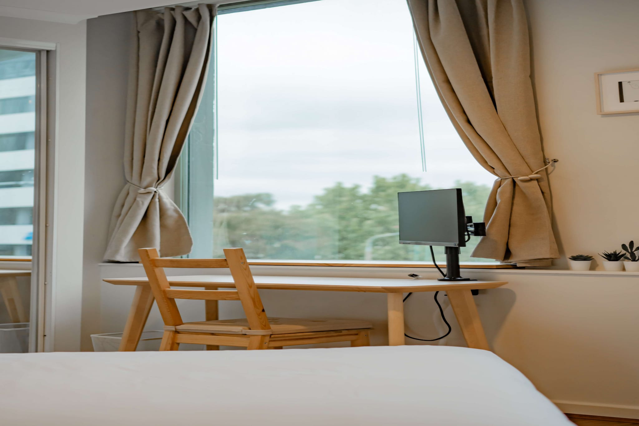 Explore Australia's capital city in this chic 2-bed apartment in Canberra’s heart. Featuring refined interiors with a Japanese twist the unit offers a private balcony with outdoor seating, bedroom balcony access, a master ensuite and on-site gym facilities available. Situated minutes from the bustling Lonsdale nightlife strip, Canberra Centre shops and Civic Square, engross yourself in this idyllic apartment's brimming potential as a base of exploration.
The space
Modernly designed, this sleek apartment features a refined style with a Japanese twist that's accentuated by the abundance of natural light and warm wooden tones. Featuring an open-plan living area, a study nook with a sleek kitchen, modern appliances, elegant bathrooms, a private balcony with outdoor seating and gorgeous bedrooms with study nooks including monitors and balcony access. Indulge in the pristine feel of this idyllic property.
 
General
- Chic 2-bedroom, 2-bathroom apartment
- Wi-Fi is provided
- Close to public transport
- Parking available (for 1 small car)
- Blackout blinds available (Living room and bedrooms)
- Gym facilities available for use
- Bedroom study nooks available
- Air conditioning and heating available
- Private balcony with outdoor seating available
- Contemporary interiors with chic decor and furnishings
- Great location moments from parks, shops, cafes and the CBD
- Self check-in
 
Bedroom
- Bedroom 1: 1x Queen Bed with a desk, built-in-robes, ensuite and balcony access.
- Bedroom 2: 1x Queen Bed with a desk and built-in-robes.
- Blackout blinds available
- Air conditioner and heater
 
Living Room
- Plush couch, armchair and coffee table
- TV with free-to-air and streaming options (Netflix and YouTube - use your own account)
- 4-seater dining table.
- Blackout blinds
- Air conditioner and heating
 
Kitchen
- Fully equipped with cookware, utensils and cutlery
- Toaster, kettle, coffee machine and microwave
- Oven and electric stovetop
- Dishwasher available
 
Bathroom & Laundry
- Sleek bathrooms
- Laundry unit available with a washer and dryer.
- Travel essentials, towels and hairdryer provided.
 
Points of Interest
Canberra Centre - 6 minutes (400m) walk away.
Lonsdale St Dining and Nightlife Strip - 6 minutes (400m) walk away.
Civic Square, Museum and Theatre - 11 minutes (800m) walk away.
Local area description
Canberra the suburb is famously the commercial centre of Australia’s capital city. Known for its numerous shops, cafes, restaurants and entertainment facilities, Canberra is the central suburb to explore the rest of the city. With ample amounts of public transport and loads of nearby parking, you won’t have to go far to find attractions for everyone. Home to the Canberra Museum, Canberra Centre, Canberra Theatre Centre and National Convention Centre, there's always something on to keep visitors busy.
House rules
You are staying in a friendly and peaceful neighbourhood and we kindly ask you to respect the community and your surrounding neighbours. The following strict House Rules apply:
- No loud noise between 10 pm and 8 am
- No parties or antisocial behaviour
- No additional people are to access the property without our prior approval
- No pets are allowed in the property without approval
- No smoking is allowed at any times
- If you break something, please let us know
- To help protect all floor coverings do not wear any shoes inside the property
 
Please be aware that excessive noise such as amplified music, vocals or screaming or anti-social behaviour in the property or common areas can cause neighbours to complain to us, the Building Manager, Council Rangers or Police.
 
IMPORTANT: Any breach of the House Rules may lead to a $500 fine plus compensation for any cost/damage created and immediate eviction of the property.
 
Finally, when checking out, we kindly ask you for the following:
- Please leave all beds unmade
- Please clean up your dishes and put them away
- In case you have rearranged furniture, please put it back to the original location
- Please take out the rubbish and remember to use the right bins
- Please ensure all appliances, A/C and lights are off and doors and windows are closed
Interaction with guests
Welcome to MadeComfy! Our local team curates stays in exceptional Australian & New Zealand properties, ensuring style, comfort, and prime locations for discerning guests. We prioritise your needs to provide a memorable home-away-from-home experience. Explore our digital guidebooks for local recommendations, and don't hesitate to contact us throughout your stay. We're here to ensure your comfort – enjoy your stay with MadeComfy.
Notes
- For your comfort, this property is prepared with professional-grade hotel-style linen, including a three-sheet setup, ensuring a fresh and hygienic sleep experience.
- To access the on-site parking use the main garage entrance.
- The parking space is very small and it will only fit a small city car.
 
Extra Services:
- Early check-in: Our standard check-in is at 3 pm. To guarantee early access to the property we suggest booking the night before if available. Otherwise, early check-in is subject to availability from the night before at an additional cost.
- Late check-out: Our standard check-out is at 10 am. To guarantee a later check-out of the property we suggest booking an additional night if available. Otherwise, a late check-out is subject to availability from the night before to an additional cost.
-