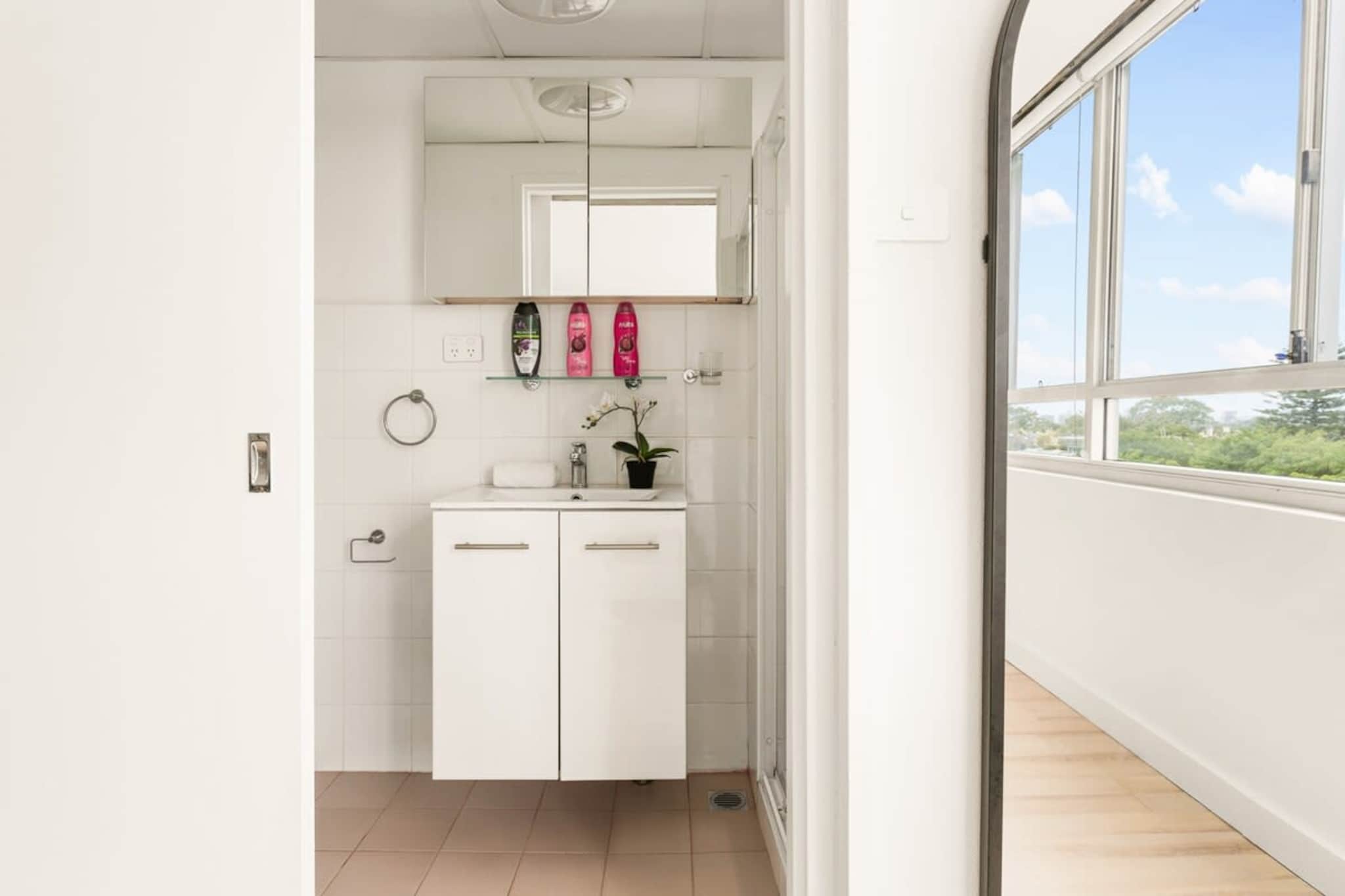 Immerse yourself in Sydney’s iconic Eastern suburbs in this chic studio only moments from shops. Featuring an elevated contemporary style, this modest property offers an abundance of natural light coupled with expansive views to enjoy. Situated near the bustling Westfield shopping centre, markets, local cafes, popular eateries and bars, relish in the vibrant local atmosphere. A short trip from the city and iconic Bondi Beach, this property is the perfect spot to explore Sydney.
The space
Generously designed, this pristine apartment features sleek interiors accentuated by an abundance of natural light. Offering a chic open living plan, an elegant kitchen, modern appliances, a sleek bathroom, a comfortable bedroom area and gorgeous window views. Relish in the apartment's incredible atmosphere and location, the perfect base to experience all the city’s east has to offer.
 
General
- Chic studio apartment with 1 bathroom
- WI-WI available
- Close to public transport
- Blackout blinds
- Portable fan and Heater available for use
- Abundance of natural light with expansive city views
- Contemporary interiors with chic decor and furnishings
- Great location near the Westfield Shopping Centre and Queens Park
- Pool
 
Living Room & Bedroom
- 1x Queen Bed
- Blackout blinds available
- Plush couch and coffee table
- TV with free-to-air channels available
- 2-seater dining table
 
Kitchen
- Fully equipped with cookware, utensils and cutlery
- Toaster, kettle and microwave
- Oven and electric stovetop
 
Bathroom & Laundry
- Sleek bathrooms
- Communal laundry room available with washer and dryer
- Travel essentials, towels and hairdryer provided.
 
Points of Interest
- Oxford St Mall and The Junction Markets - 3 minutes (220m) walk away.
- Westfield Bondi Junction Shopping Centre - 4 minutes (350m) walk away.
- Queens Park - 10 minutes (700m) walk away.
Local area description
Bondi Junction is a bustling shopping and transport hub nestled in Sydney’s idyllic eastern suburbs. Home to an impressive Westfield shopping centre full of dining options, designer labels, and popular restaurants, relish in the shopping centre's wide array of shops. Surrounded by shopping strips, malls and more, indulge in the numerous nearby eateries, local cafes, and weekly markets. A popular hub of activity, Bondi Junction acts as a commercial gateway to the idyllic beaches and parks of Sydney’s pristine eastern suburbs.
House rules
You are staying in a friendly and peaceful neighbourhood and we kindly ask you to respect the community and your surrounding neighbours. The following strict House Rules apply:
 
- No loud noise between 10 pm and 8 am
- No parties or antisocial behaviour
- No additional people are to access the property without our prior approval
- No pets are allowed in the property without approval
- No smoking is allowed at any times
- If you break something, please let us know
 
- To help protect all floor coverings do not wear any shoes inside the property
 
Please be aware that excessive noise such as amplified music, vocals or screaming or anti-social behaviour in the property or common areas can cause neighbours to complain to us, the Building Manager, Council Rangers or Police.
 
IMPORTANT: Any breach of the House Rules may lead to a $500 fine plus compensation for any cost/damage created and immediate eviction of the property.
 
Finally, when checking out, we kindly ask you for the following:
 
- Please leave all beds unmade
- Please clean up your dishes and put them away
- In case you have rearranged furniture, please put it back to the original location
- Please take out the rubbish and remember to use the right bins
- Please ensure all appliances, A/C and lights are off and doors and windows are closed.
Interaction with guests
Welcome to MadeComfy! Our local team curates stays in exceptional Australian & New Zealand properties, ensuring style, comfort, and prime locations for discerning guests. We prioritise your needs to provide a memorable home-away-from-home experience. Explore our digital guidebooks for local recommendations, and don't hesitate to contact us throughout your stay. We're here to ensure your comfort – enjoy your stay with MadeComfy.
Notes
- For your comfort, this property is prepared with professional-grade hotel-style linen, including a three-sheet setup, ensuring a fresh and hygienic sleep experience.
- There is no on-site parking available for use. All street parking is time limited.
- There are stairs inside the building.
 
Extra Services:
- Early check-in: Our standard check-in is at 3 pm. To guarantee early access to the property we suggest booking the night before if available. Otherwise, early check-in is subject to availability from the night before at an additional cost.
- Late check-out: Our standard check-out is at 10 am. To guarantee a later check-out of the property we suggest booking an additional night if available. Otherwise, a late check-out is subject to availability from the night before to an additional cost.
- Baggage: For security reasons, we are unable to receive or to keep unattended baggage before check-in or after check-out
- We provide a small welcome amenity pack to get your stay started
- Pets are not allowed.
- This booking is protected with coverage for lost baggage and emergency medical expenses, provided by Travel Support with claim upto 500 AUD (T&C Applies). For more details reach out to Guest Support team post booking.
Access description
You’ll have access to the entire property when you stay here, so it will feel like your own home. The keys will be left in a lockbox.
Getting around
Public transport
The property is near numerous bus stops operating trips to The Star, Rozelle, Marrickville Metro, Bondi Junction, Eastgardens, Pagewood, North Bondi, La Perouse, Clovelly, Qantas Domestic Terminal, Bronte, Coogee Beach and City. Additionally, the nearby Bondi Junction train station operates trips to Central, Cronulla and Waterfall
 
Ride sharing
There is plenty of taxi and ride-sharing options readily available throughout Sydney.
 
Points of Interest
Oxford St Mall and The Junction Markets - 3 minutes (220m) walk away.
Westfield Bondi Junction Shopping Centre - 4 minutes (350m) walk away.
Queens Park - 10 minutes (700m) walk away.
 
Getting there
The property is roughly a 20-minute drive from Sydney Airport.