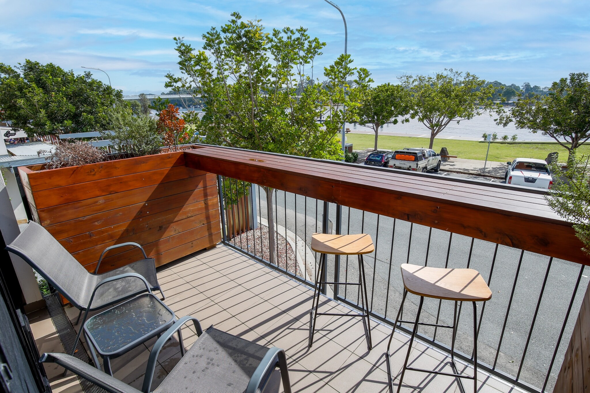 Immerse yourself in the picturesque South Coast in this charming 2-bed apartment only metres from shops. Featuring chic interiors this homely property includes a cosy balcony with outdoor seating, a stool bench and views overlooking the Clyde River. Situated mere metres from the Bridge Plaza and Village Centre shops the property also boasts proximity to the local marina, animal park and beaches. For those seeking a pristine and convenient property, this is the spot for you.
The space
Thoughtfully designed, this chic apartment features homely interiors accentuated by an abundance of natural light. Offering an open-plan living area, modern appliances, a polished kitchen, a sleek bathroom, stunning bedrooms and a cosy balcony with outdoor seating and views overlooking the Clyde River. Experience this property’s welcoming atmosphere in a truly unbeatable location.
General
- Chic 2-bedroom, 1-bathroom apartment
- Wifi available
- On-site parking available (1 spot)
- Close to public transport
- A/C, heating and fans available
- Modern interiors with contemporary decor and furnishings
- Stunning balcony with outdoor seating and views overlooking the river
- Great location in the heart of Batemans Bay and near the local beach
- Self check-in
Bedroom
- Bedroom 1: 1x Queen Bed with BIR
- Bedroom 2: 1x Queen Bed with BIR
- Blackout blinds available
- Ceiling fans available in both rooms
Living Room
- Elegant couch and a coffee table
- TV with free-to-air and streaming options
- A/C and heating available
- Blackout blinds available
- 4-seater dining table
Kitchen
- Fully equipped with premium cookware, utensils and cutlery
- Toaster, kettle, coffee machine and microwave are available
- Oven and electric stovetop
Bathroom & Laundry
- Sleek bathroom available
- Laundry unit available with a washer/dryer combo
- Travel essentials, towels and hairdryer provided