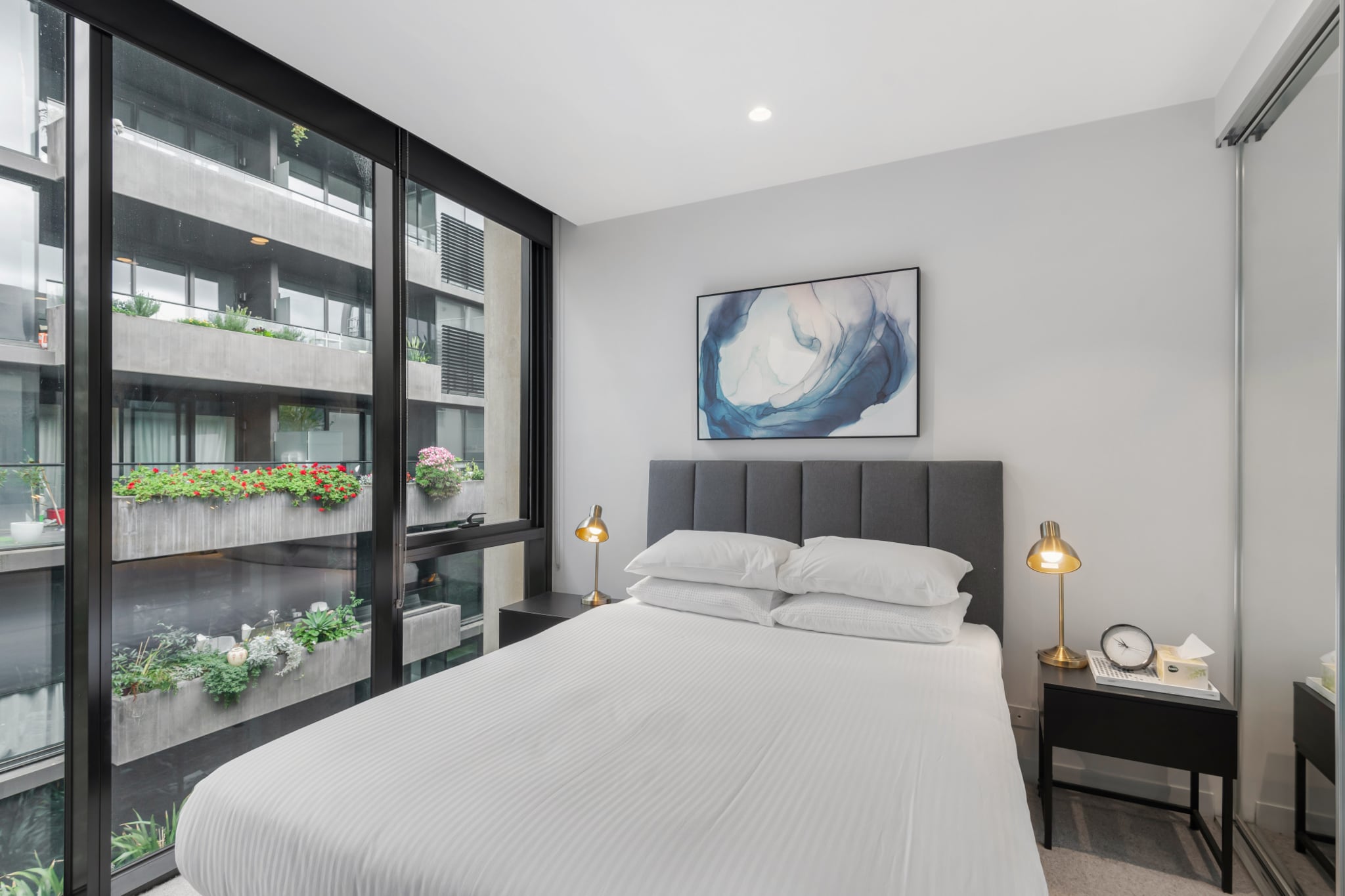 Immerse yourself in Melbourne's inner-city in this charmingly snug 1-bed apartment. Featuring sleek modern interiors this gorgeous property boasts a private balcony with outdoor seating along with access to the on-site garden, BBQ area and outdoor pool facilities. Situated moments from the bustling Smith and Johnston shopping, dining and nightlife strips, relish in the eclectic local neighbourhood populated with boutique stores, bespoke bars and incredible restaurants.
The space
Meticulously designed, this chic apartment offers sleek contemporary interiors accentuated by an abundance of natural light. Featuring an open-plan living area, modern appliances, a sleek kitchen, polished bathrooms, gorgeous bedrooms and a private balcony with outdoor seating available. Experience for yourself this property’s perfectly curated atmosphere equipped with everything you’d need for an unforgettable stay.
 
General
- Chic 1-bedroom, 1-bathroom apartment.
- Close to public transport.
- A/C and heating available (living room only).
- WIFI.
- On-site parking is available (1 spot)
- Private balcony with outdoor seating available.
- Study nook with spacious desk as working area
- On-site communal garden, BBQ area and an outdoor pool are available.
- Generous communal terrace with outdoor lounge and dining available for use.
- Incredible location between the bustling Smith and Johnston St shops.
 
Bedroom
- Bedroom 1: 1x Queen bed.
- Blackout blinds are available.
 
Living room
- Plush couch, armchair and coffee table are available.
- TV with streaming options available (use your own account).
- 4-seater dining table available.
- Blackout blinds are available.
- A/C and heating available.
 
Kitchen
- Fully equipped with cookware, utensils and cutlery.
- Toaster, kettle, coffee machine and microwave are available.
- Oven and a gas stovetop available.
- Dishwasher available.
 
Bathroom
- Sleek bathrooms are available.
- Travel essentials, towels and a hairdryer are provided.
- Laundry is available with a washer and dryer.
 
Points of Interest
- Smith St Shopping and Dining Strip – 3 minutes (250m) walk away.
- Johnston St Shopping Strip – 4 minutes (400m) walk away.
- Melbourne Cricket Ground –7 minutes (2.3km) drive away.
Local area description
Collingwood is one of Melbourne’s famous inner city suburbs, located in the inner-city the suburb is known for its lively bohemian atmosphere. Famously popular among young students and professionals the suburb offer s rich array of eclectic stores and venues to explore. Boasting bustling inner city streets filled with cafes, restaurants, pubs and markets, the neighbourhood offers proximity to the Fitzroy Gardens, the MCG and the CBD. In such a central location Collingwood with its iconic Victorian townhouses is the perfect suburb to explore all that Melbourne has to offer.
House rules
You are staying in a friendly and peaceful neighbourhood and we kindly ask you to respect the community and your surrounding neighbours. The following strict House Rules apply:
 
- No loud noise between 10 pm and 8 am
- No parties or antisocial behaviour
- No additional people are to access the property without our prior approval
- No smoking is allowed at any times
- If you break something, please let us know
- To help protect all floor coverings do not wear any shoes inside the property
 
Please be aware that excessive noise such as amplified music, vocals or screaming or anti-social behaviour in the property or common areas can cause neighbours to complain to us, the Building Manager, Council Rangers or Police.
 
IMPORTANT: Any breach of the House Rules may lead to a $500 fine plus compensation for any cost/damage created and immediate eviction of the property.
 
Finally, when checking out, we kindly ask you for the following:
 
- Please leave all beds unmade
- Please clean up your dishes and put them away
- In case you have rearranged furniture, please put it back to the original location
- Please take out the rubbish and remember to use the right bins
- Please ensure all appliances, A/C and lights are off and doors and windows are closed
Interaction with guests
Welcome to MadeComfy! Our local team curates stays in exceptional Australian & New Zealand properties, ensuring style, comfort, and prime locations for discerning guests. We prioritise your needs to provide a memorable home-away-from-home experience. Explore our digital guidebooks for local recommendations, and don't hesitate to contact us throughout your stay. We're here to ensure your comfort – enjoy your stay with MadeComfy.
Notes
- For your comfort, this property is prepared with professional-grade hotel-style linen, including a three-sheet setup, ensuring a fresh and hygienic sleep experience.
- The parking garage is next to the front building entrance.
 
Extra Services:
- Early check-in: Our standard check-in is at 3 pm. To guarantee early access to the property we suggest booking the night before if available. Otherwise, early check-in is subject to availability from the night before at an additional cost.
- Late check-out: Our standard check-out is at 10 am. To guarantee a later check-out of the property we suggest booking an additional night if available. Otherwise, a late check-out is subject to availability from the night before to an additional cost.
- Baggage: For security reasons, we are unable to receive or to keep unattended baggage before check-in or after check-out
- We provide a small welcome amenity pack to get your stay started
- No pets allowed.
- This booking is protected with coverage for lost baggage and emergency medical expenses, provided by Travel Support with claim upto 500 AUD (T&C Applies). For more details reach out to Guest Support team post booking.
Access description
- To access the property, walk up towards the glass door, and scan the fob on the black reader to enter the building. Walk in and turn left towards the lift.
- You’ll have access to the entire property, so it will feel like your own home.
- There are few stairs entering the property though there is a ramp. Wheelchair friendly.
- Key collection is offsite, 850 meters from the property and not available 24/7. Further details will be provided 3 days before check-in if your booking is successfully reserved.
Getting around
Public transport
There are tram stops on Smith St operating trips to Docklands and Bundoora RMIT. Additionally, bus stops on Johnston St operate trips to Bulleen, Doncaster SC and City.
 
Ride sharing
There are plenty of taxi and ride-sharing options readily available throughout Collingwood.
 
Points of Interest
Smith St Shopping and Dining Strip – 3 minutes (250m) walk away.
Johnston St Shopping Strip – 4 minutes (400m) walk away.
Melbourne Cricket Ground –7 minutes (2.3km) drive away.
 
Getting there
The property is approximately a 20-minute drive from Melbourne’s CBD or a 30-minute drive from Melbourne Airport.