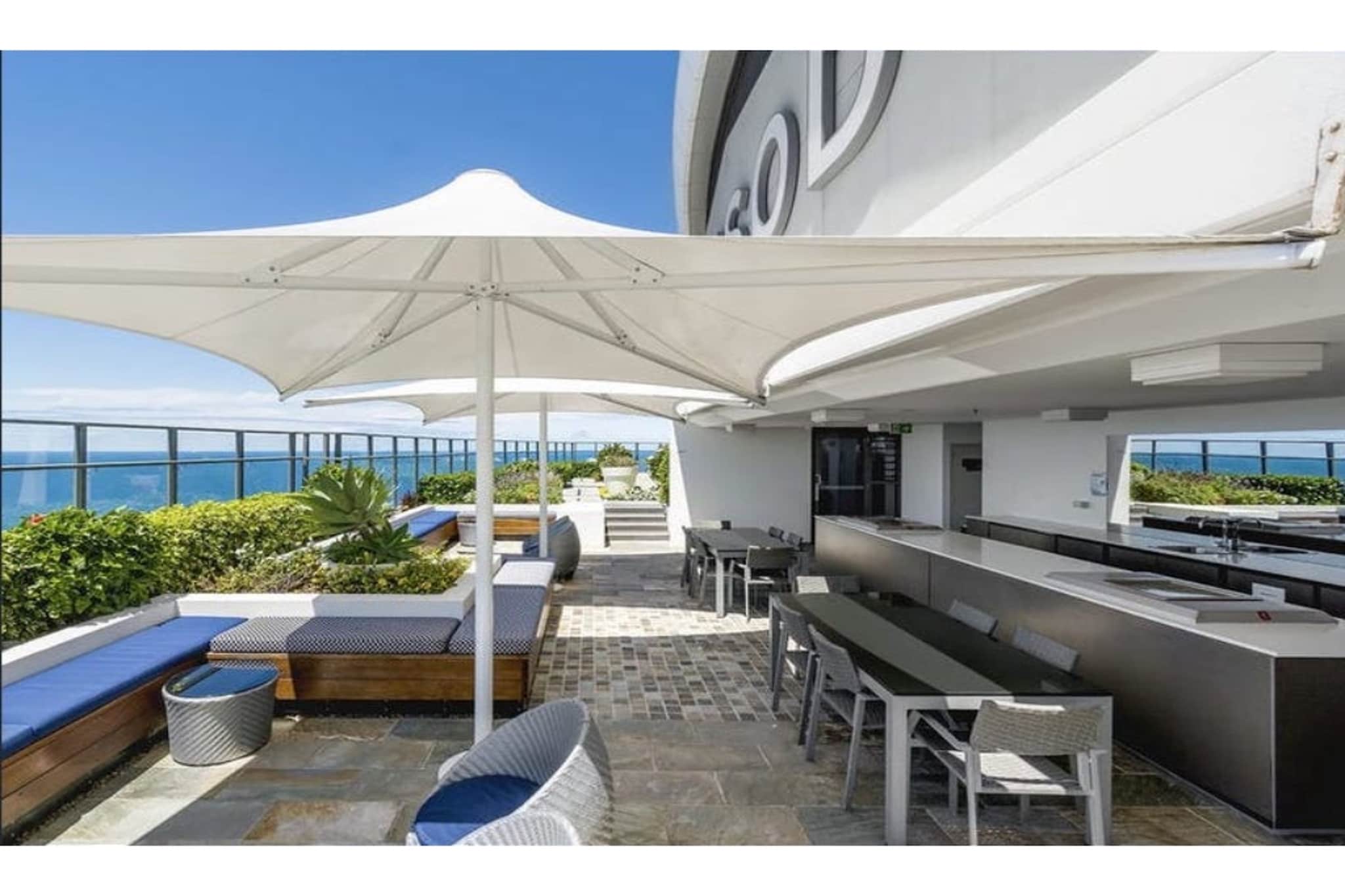 Indulge in Surfer's iconic atmosphere from this wonderful 2-bed apartment with scenic views. Featuring a private balcony with outdoor dining and expansive ocean views, this modern apartment boasts generous amenities including a pool, gym and panoramic rooftop views. Situated across from the beach, relish in the wide array of cafes, dining, shopping and nightlife venues only a short distance from the property. For those seeking a peaceful base to experience the coast, look no further.
The space
Impeccably designed, this contemporary apartment offers refined interiors accentuated by an abundance of natural light and views. Featuring an open-plan living area, a sleek kitchen, modern appliances, polished bathrooms, pristine bedrooms, a master ensuite and a gorgeous balcony with outdoor dining and stunning ocean views. Experience for yourself this property’s perfectly curated atmosphere with everything you’d need for an unforgettable stay.
Note: Please be aware that there is ongoing construction at the site.
General
- Chic 2-bedroom, 2-bathroom apartment
- Close to public transport
- Wi-Fi is available
- Blackout blinds
- A/C and heating available in the living and bedrooms
- Modern interiors with contemporary interiors and furnishings
- Beautiful balcony with outdoor dining and stunning ocean views
- On-site BBQ area, gym, a pool and a rooftop terrace with panoramic views
- Incredible location near the heart of Surfers Paradise and the iconic beachside
Bedroom
- Bedroom 1: 1x King bed with a TV, walk-in robe and ensuite
- Bedroom 2: 2x Single beds
- A/C and heating are available in both bedrooms
- Blackout blinds are available
Living Room
- Plush couch, armchair and coffee table
- TV with free-to-air and streaming options
- A/C and heater
- Blackout blinds
- Study nook
- 4-seater dining table
Kitchen
- Fully equipped with cookware, utensils and cutlery
- Toaster, kettle, coffee machine and microwave
- Oven and a gas stovetop
- Dishwasher
Bathroom & Laundry
- Sleek bathrooms are available
- Laundry unit with a washer and dryer available
- Travel essentials, towels and a hairdryer are provided
Points of Interest
Surfers Paradise Beach - 1 minute (100m) walk away.
Cavill Avenue Shopping Precinct - 3 minutes (1.3km) drive away.
Chevron Renaissance Shopping Centre - 3 minutes (1.3km) drive away.
House rules
You are staying in a friendly and peaceful neighbourhood and we kindly ask you to respect the community and your surrounding neighbours. The following strict House Rules apply:
- No loud noise between 10 pm and 8 am
- No parties or antisocial behaviour
- No additional people are to access the property without our prior approval
- No pets are allowed in the property without approval
- No smoking is allowed at any times
- If you break something, please let us know
- To help protect all floor coverings do not wear any shoes inside the property
Please be aware that excessive noise such as amplified music, vocals or screaming or anti-social behaviour in the property or common areas can cause neighbours to complain to us, the Building Manager, Council Rangers or Police.
IMPORTANT: Any breach of the House Rules may lead to a $500 fine plus compensation for any cost/damage created and immediate eviction of the property.
Finally, when checking out, we kindly ask you for the following:
- Please leave all beds unmade
- Please clean up your dishes and put them away
- In case you have rearranged furniture, please put it back to the original location
- Please take out the rubbish and remember to use the right bins
- Please ensure all appliances, A/C and lights are off and doors and windows are closed.
Interaction with guests
Welcome to MadeComfy! Our local team curates stays in exceptional Australian & New Zealand properties, ensuring style, comfort, and prime locations for discerning guests. We prioritise your needs to provide a memorable home-away-from-home experience. Explore our digital guidebooks for local recommendations, and don't hesitate to contact us throughout your stay. We're here to ensure your comfort – enjoy your stay with MadeComfy.
Notes
- For your comfort, this property is prepared with professional-grade hotel-style linen, including a three-sheet setup, ensuring a fresh and hygienic sleep experience.
- There is no on-site parking available. Though the Gypress Gardens paid parking lot is located nearby.
- The unit is only available via a lift.
- There are ongoing constructions works happening on the building next door until further notice, some noise is expected
Extra Services:
- Early check-in: Our standard check-in is at 3 pm. To guarantee early access to the property we suggest booking the night before if available. Otherwise, early check-in is subject to availability from the night before at an additional cost.
- Late check-out: Our standard check-out is at 10 am. To guarantee a later check-out of the property we suggest booking an additional night if available. Otherwise, a late check-out is subject to availability from the night before to an additional cost.
- Baggage: For security reasons, we are unable to receive or to keep unattended baggage before check-in or after check-out
- We provide a small welcome amenity pack to get your stay started
- This booking is protected with coverage for lost baggage and emergency medical expenses, provided by Travel Support with claim upto 500 AUD (T&C Applies). For more details reach out to Guest Support team post booking.
Access description
- You’ll have access to the entire property when you stay here, so it will feel like your own home.
- There are no stairs outside or inside the property.
- The key collection is located offsite, 1.2 km away from the property, and available 24/7. Further details will be provided 3 days before check-in if your booking is successfully reserved.
Getting around
Public transport
The property is moments from the Surfers Paradise North light rail stop, which operates a route from Helensvale to Broadbeach South. Additionally, nearby bus stops operate trips to Home of the Arts, Sea World, Brisbane and Sydney.
Ride sharing
There is plenty of taxi and ride-sharing options readily available throughout Surfers Paradise.
Points of Interest
Surfers Paradise Beach - 1 minute (100m) walk away.
Cavill Avenue Shopping Precinct - 3 minutes (1.3km) drive away.
Chevron Renaissance Shopping Centre - 3 minutes (1.3km) drive away.
Getting there
The property is approximately a 30-minute drive from Gold Coast Airport.