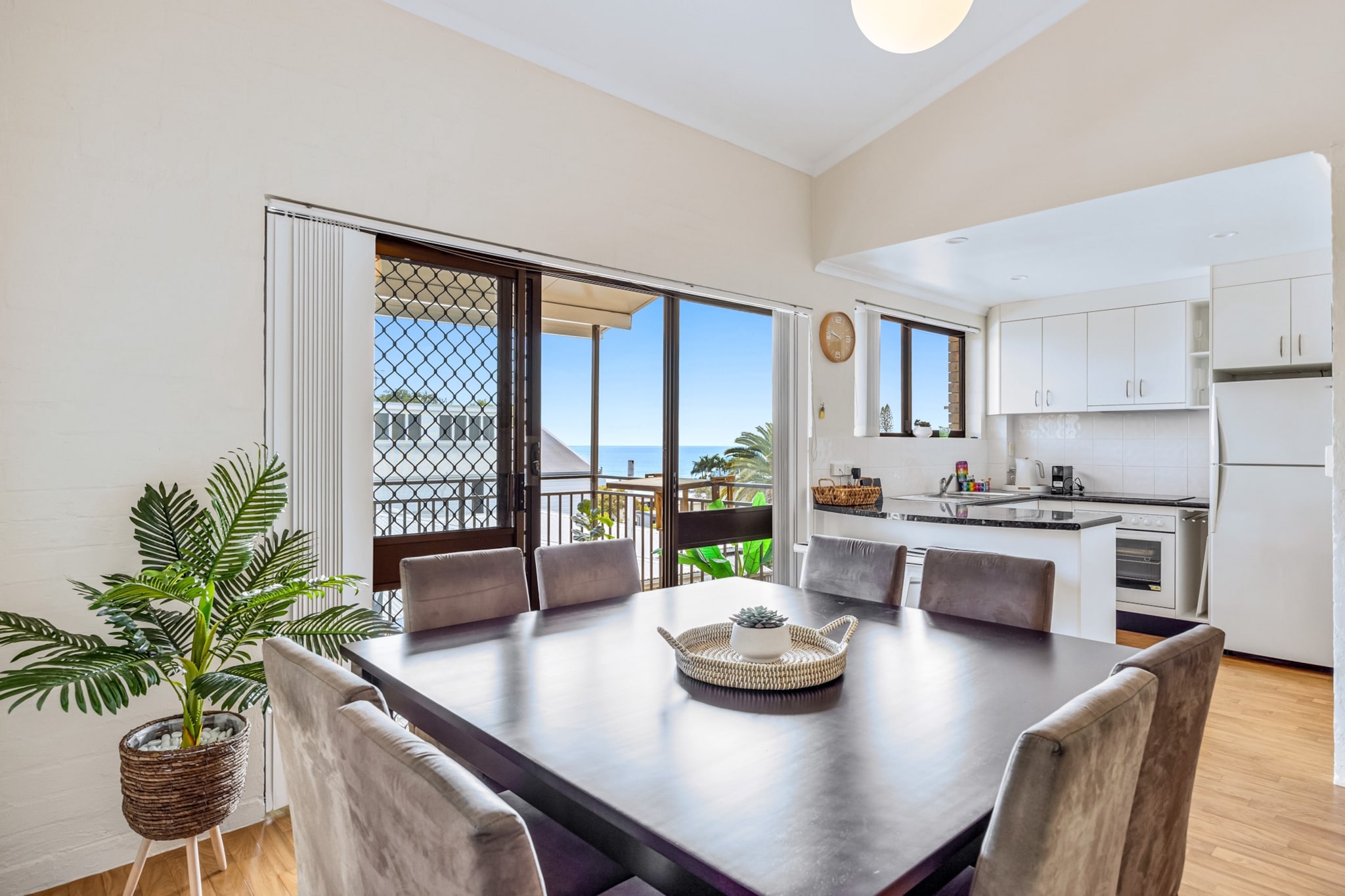 Located 400 metres from one of Sunshine Coast's most famous surf beaches, this incredible 2-bed, 1-bath unit offers ocean views and large windows that allow natural light to seamlessly pour in. Discover the hidden gems of Alexandra Headland Beach – such as cafes, restaurants, nature walks, and parks – which will all be within walking distance from you. Featuring self check-in, clean aesthetics, homely interiors and modern appliances, this beach pad has your name written all over it.

The space
Within walking distance from the beach and many local attractions, this charming apartment presents bright interiors, a spacious open-plan living area, serene bedrooms with built-in robes, and a sleek bathroom. Whether you plan to relax on the undercover balcony overlooking the ocean or get amongst all the surf action on the beach, this perfectly located property offers comfort and convenience. Featuring an internal laundry, garage for one car and unlimited street parking, find yourself in close proximity to nature, entertainment and public transport. Ready for a Sunshine Coast holiday for the books? All you have to do is book this property!
 
Living room
- Couch sits 4 people
- TV with Netflix available (guests to use their own account)
 
Kitchen & Dining Area
- Fully equipped with utensils and cutlery
- Oven and electric stovetop
- Countertop area sits 2 people, dining area sits 8 people
 
Bathroom & Laundry
- Laundry room available with washer and dryer
- Travel essentials, towels and hairdryer provided
 
Amenity Notes
- Split system A/C (heating + cooling) in the main bedroom
- Nestled in nature, with ocean views
- Ceiling fans in bedrooms & a portable fan in living room
- Undercover balcony with seating overlooking the ocean
- Wi-Fi is available
- Garage parking for 1 car; unlimited street parking
- Walking distance to the beach, cafes, restaurants, and parks
- Self check-in
Local area description
Alexandra Headland, a charming coastal suburb on Queensland's Sunshine Coast, has stunning beaches perfect for swimming, surfing, and sunbathing, whilst the iconic Alexandra Headland Surf Club provides a haven and a popular spot for dining and refreshments. Nearby attractions include the Foote Sanctuary of Buderim, offering a serene encounter with native wildlife, and Point Cartwright, a vantage point for breathtaking coastal vistas and whale watching. The Mooloolaba Esplanade, a short distance away, offers a vibrant hub of eateries and shops; Alexandra Beach House, known as "The Bluff", adds a touch of historic charm to the scenery. With scenic walks and cycling tracks, Alexandra Headland provides a perfect blend of natural beauty and recreational opportunities, making it a beloved destination for locals and visitors seeking the quintessential Sunshine Coast experience.
House rules
You are staying in a friendly and peaceful neighbourhood and we kindly ask you to respect the community and your surrounding neighbours. The following strict House Rules apply:
- No loud noise between 10 pm and 8 am
- No parties or antisocial behaviour
- No additional people are to access the property without our prior approval
- No pets are allowed in the property
- No smoking is allowed at any times
- If you break something, please let us know
- To help protect all floor coverings, do not wear any shoes inside the property
 
Please be aware that excessive noise such as amplified music, vocals or screaming or anti-social behaviour in the property or common areas can cause neighbours to complain to us, the Building Manager, Council Rangers or Police.
 
IMPORTANT:
- Any breach of the House Rules may lead to a $500 fine plus compensation for any cost/damage created and immediate eviction of the property without refund.
 
Finally, when checking out, we kindly ask you for the following:
- Please leave all beds unmade
- Please clean up your dishes and put them away
- In case you have rearranged furniture, please put it back to the original location
- Please take out the rubbish and remember to use the right bins
- Please ensure all appliances, A/C and lights are off and doors and windows are closed.
- Please check your accommodation thoroughly before departing to avoid any unintentional items left behind.
 
We are not liable for any items left behind after your stay. In the rare event that a guest reports a missing item, we will make every effort to locate it for you, but we cannot guarantee its retrieval. If the item is found, we will gladly assist in arranging its return to an address within Australia, subject to postage and service fees.
Interaction with guests
Welcome to MadeComfy! Our local team curates stays in exceptional Australian & New Zealand properties, ensuring style, comfort, and prime locations for discerning guests. We prioritise your needs to provide a memorable home-away-from-home experience. Explore our digital guidebooks for local recommendations, and don't hesitate to contact us throughout your stay. We're here to ensure your comfort – enjoy your stay with MadeComfy.
Notes
- For your comfort, this property is prepared with professional-grade hotel-style linen, including a three-sheet setup, ensuring a fresh and hygienic sleep experience.
- Pets are not allowed.
 
Extra Services:
- Early check-in: Our standard check-in is at 3 pm. To guarantee early access to the property we suggest booking the night before if available. Otherwise, early check-in is subject to availability from the night before at an additional cost.
- Late check-out: Our standard check-out is at 10 am. To guarantee a later check-out of the property we suggest booking an additional night if available. Otherwise, a late check-out is subject to availability from the night before to an additional cost.
- Baggage: For security reasons, we are unable to receive or to keep unattended baggage before check-in or after check-out
- We provide a small welcome amenity pack to get your stay started
- This booking is protected with coverage for lost baggage and emergency medical expenses, provided by Travel Support with claim upto 500 AUD (T&C Applies). For more details reach out to Guest Support team post booking.
Access description
- The key collection is located on a lock box onsite. Further details will be provided 3 days before check-in if your booking is successfully reserved.
- Four flights of stairs are required to access the property.
Getting around
Public transport
The closest bus stop is located 31 m away from the property on Mary St near William St. Please visit Translink's website for more information.
 
Getting There
The property is located 15 km away from Sunshine Coast Airport.
By car, the journey will take around 17 minutes. By public transportation, the journey will take around 1 hour.