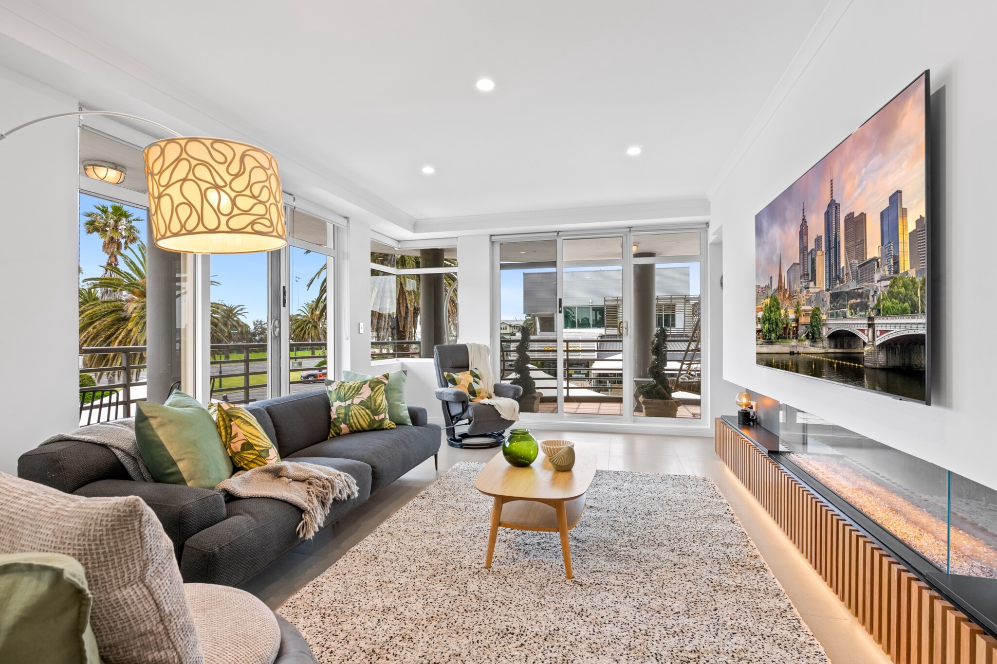 Indulge in the elegance of this sophisticated 3-bedroom apartment, a gem set against the backdrop of Beacon Cove Promenade's picturesque scenery. Revel in the luxury of self-check-in and designer interiors, with the beach, cycling trails, and a selection of fine restaurants and bars just moments away. A mere 20-minute drive from Melbourne's CBD offers the perfect mix of beachside bliss and city thrills. This is your perfect escape to a coastal haven with all the allure of city convenience.

The space
Perched by the water, this stunning 3-bedroom, 2-bathroom apartment boasts an unbeatable location. The interior is a testament to elegance, with a bright, open-plan living space leading to a spacious undercover balcony with ocean views. The kitchen is flawless, and the dining area exudes charm. Sophisticated queen bedrooms feature private balconies perfect for relaxation. The master bathroom offers a spa-like experience with a generous bath and modern fixtures. Comfort is ensured with air conditioning, ceiling fans, and a verdant communal area complete with picnic tables. Situated conveniently close to all necessities, this property promises an impeccable stay.
 
Living room
- Couch sits 5 people
- TV with multiple streaming options to be used with guest's account
 
Kitchen & Dining Area
- Fully equipped with utensils and cutlery
- Oven and gas stovetop
- Dining area sits 4 people
 
Bathroom & Laundry
- Laundry room available with washer and dryer
- Travel essentials, towels and hairdryer provided
 
Amenity Notes
- Ducted split system A/C throughout
- Ceiling fans in bedrooms
- Portable heater available
- Wi-Fi available
- Main undercover balcony by living area plus private balconies in each bedroom
- Access to building's communal garden with picnic table
- No parking available
Local area description
Port Melbourne, located about 5 kilometres southwest of Melbourne's CBD, is an inner-city suburb in Victoria. Once a thriving industrial and commercial hub due to its proximity to the Port of Melbourne, it has undergone substantial urban renewal, transforming into a more residential and recreational area. Notable features include its picturesque beaches, such as Port Melbourne Beach and South Melbourne Beach, along with the bustling Bay Street, known for its shops, cafes, and restaurants. The suburb also boasts historical landmarks like Station Pier, which continues to serve as a gateway for cruise ships, and the Gasworks Arts Park, a cultural precinct hosting various events and exhibitions. Port Melbourne combines maritime heritage with modern amenities, making it a sought-after area for its coastal lifestyle and accessibility to the city.
House rules
You are staying in a friendly and peaceful neighbourhood and we kindly ask you to respect the community and your surrounding neighbours. The following strict House Rules apply:
 
- No loud noise between 10 pm and 8 am
- No parties or antisocial behaviour
- No additional people are to access the property without our prior approval
- No pets are allowed in the property without approval
- No smoking is allowed at any times
- If you break something, please let us know
- To help protect all floor coverings, do not wear any shoes inside the property
 
Please be aware that excessive noise such as amplified music, vocals or screaming or anti-social behaviour in the property or common areas can cause neighbours to complain to us, the Building Manager, Council Rangers or Police.
 
IMPORTANT:
- Any breach of the House Rules may lead to a $500 fine plus compensation for any cost/damage created and immediate eviction of the property without refund.
- Pets are available on request unless the property states it is pet friendly. Any stays with pets will incur an additional cleaning fee of $200.
 
Finally, when checking out, we kindly ask you for the following:
 
- Please leave all beds unmade
- Please clean up your dishes and put them away
- In case you have rearranged furniture, please put it back to the original location
- Please take out the rubbish and remember to use the right bins
- Please ensure all appliances, A/C and lights are off and doors and windows are closed.
- Please check your accommodation thoroughly before departing to avoid any unintentional items left behind.
 
We are not liable for any items left behind after your stay. In the rare event that a guest reports a missing item, we will make every effort to locate it for you, but we cannot guarantee its retrieval. If the item is found, we will gladly assist in arranging its return to an address within Australia, subject to postage and service fees.
Interaction with guests
Welcome to MadeComfy! Our local team curates stays in exceptional Australian & New Zealand properties, ensuring style, comfort, and prime locations for discerning guests. We prioritise your needs to provide a memorable home-away-from-home experience. Explore our digital guidebooks for local recommendations, and don't hesitate to contact us throughout your stay. We're here to ensure your comfort – enjoy your stay with MadeComfy.
Notes
- For your comfort, this property is prepared with professional-grade hotel-style linen, including a three-sheet setup, ensuring a fresh and hygienic sleep experience.
- The apartment is near the main road, providing convenient access to Melbourne's lively heart and the authentic ambiance of a bustling area.
 
Extra Services:
- Early Check-in: Our standard check-in is at 3 pm. To guarantee early access to the property we suggest booking the night before if available. Otherwise, early check-in is subject to availability from the night before at an additional cost.
- Late check-out: Our standard check-out is at 10 am. To guarantee a later check-out of the property we suggest booking an additional night if available. Otherwise, a late check-out is subject to availability from the night before to an additional cost.
- Baggage: For security reasons, we are unable to receive or to keep unattended baggage before check-in or after check-out
- We provide a small welcome amenity pack to get your stay started
- This booking is protected with coverage for lost baggage and emergency medical expenses, provided by Travel Support with claim upto 500 AUD (T&C Applies). For more details reach out to Guest Support team post booking.
Access description
- Stairs are required to access the entrance of the building and the front door of the property.
 
- Key collection is offsite, 900 meters from the property, and not available 24/7.
 
- Please note, that key collection is available only during the store's advertised opening hours. While we rely on the store to remain open during its advertised hours, any unforeseen changes are beyond our control, and no alternative collection is available after closing. Further details about your booking will be provided three days before your check-in, upon successful reservation confirmation.
Getting around
Public transport
The closest tram stop is located 170 m away from the property on Beacon Cove/Light Rail. The closest bus stop is located 176 m away from the property on Port Melbourne Station/Beach St. Please visit Transport Victoria's website for more information.
 
Getting There
The property is located 27 km away from Melbourne Airport.
By car, the journey will take around 25 minutes. By public transportation, the journey will take around 1 hour.