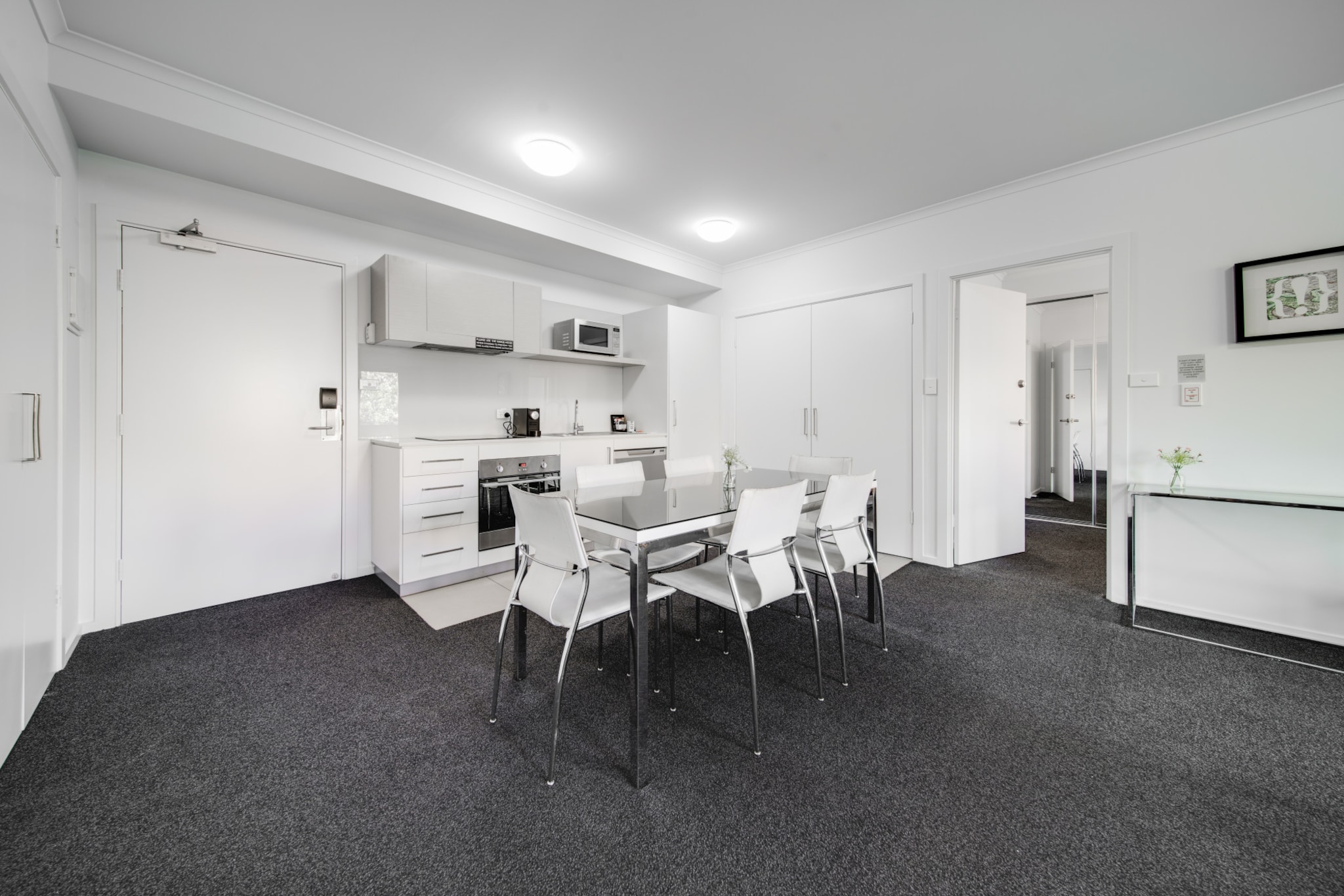 This spacious, executive 2-bed apartment is conveniently placed a short ride from Canberra's CBD in the beautiful lakeside district of Greenway. Featuring bright and generous interiors, this unit is within walking distance to shops, restaurants, and public transport. Enjoy the nearby parks, reserves, and Lake Tuggeranong. Whether for work or leisure, it's a great place to stay in the ACT with self-check-in.
The space
Located in Greenway, right by the lake, this well-planned apartment is all about making your life easy. Inside, you'll find two generous king-sized bedrooms with robes, a master bedroom with an ensuite, a modern bathroom, and a stylish kitchen—part of a spacious open-plan living area where a comfy living room and a dining table can also be found. Stepping outside, you'll have an undercover balcony from which you can take in the lively neighborhood surrounding you. This property features air conditioning, internal laundry, and underground parking for two vehicles. A short walk away from restaurants, cafes, and all the outdoor fun around Lake Tuggeranong, this incredible apartment also offers nearby public transport directly to the CBD. If you seek convenience, this is the property for you.
 
Living room
- Couch sits 4 people
- TV with free air channels
 
Kitchen & Dining Area
- Fully equipped with utensils and cutlery
- Oven and induction stovetop
- Dining area sits 6 people
 
Bathroom & Laundry
- Laundry room available with washer and dryer
- Travel essentials, towels and hairdryer provided
 
Amenity Notes
- Wall-mounted split system A/C (heating + cooling) in the living area
- Underground parking for two standard vehicles
- Private undercover balcony off living area
- No Wi-Fi
- Self check-in
Local area description
Bordered by the Tuggeranong Lake and nestled against the Tuggeranong Hill Nature Reserve, Greenway is known for its scenic surroundings. The suburb is characterised by its residential areas and recreational spaces, making it a popular choice for people seeking a mix of nature and urban amenities. With many parks, hike trails and recreational areas, outdoor opportunities in Greenway are plentiful. The suburb is also home to a major shopping centre with a wide range of retail shops, restaurants, and entertainment options. Greenway is well-connected to other parts of Canberra through roads and public transportation.
House rules
You are staying in a friendly and peaceful neighbourhood and we kindly ask you to respect the community and your surrounding neighbours. The following strict House Rules apply:
- No loud noise between 10 pm and 8 am
- No parties or antisocial behaviour
- No additional people are to access the property without our prior approval
- No pets are allowed in the property without approval
- No smoking is allowed at any times
- If you break something, please let us know
- To help protect all floor coverings, do not wear any shoes inside the property
 
Please be aware that excessive noise such as amplified music, vocals or screaming or anti-social behaviour in the property or common areas can cause neighbours to complain to us, the Building Manager, Council Rangers or Police.
 
IMPORTANT:
 
- Any breach of the House Rules may lead to a $500 fine plus compensation for any cost/damage created and immediate eviction of the property without refund.
- Pets are available on request unless the property states it is pet-friendly. Any stays with pets will incur an additional cleaning fee of $200.
 
Finally, when checking out, we kindly ask you for the following:
- Please leave all beds unmade
- Please clean up your dishes and put them away
- In case you have rearranged furniture, please put it back to the original location
- Please take out the rubbish and remember to use the right bins
- Please ensure all appliances, A/C and lights are off and doors and windows are closed.
- Please check your accommodation thoroughly before departing to avoid any unintentional items left behind.
 
We are not liable for any items left behind after your stay. In the rare event that a guest reports a missing item, we will make every effort to locate it for you, but we cannot guarantee its retrieval. If the item is found, we will gladly assist in arranging its return to an address within Australia, subject to postage and service fees.
Interaction with guests
Welcome to MadeComfy! Our local team curates stays in exceptional Australian & New Zealand properties, ensuring style, comfort, and prime locations for discerning guests. We prioritise your needs to provide a memorable home-away-from-home experience. Explore our digital guidebooks for local recommendations, and don't hesitate to contact us throughout your stay. We're here to ensure your comfort – enjoy your stay with MadeComfy.
Notes
- For your comfort, this property is prepared with professional-grade hotel-style linen, including a three-sheet setup, ensuring a fresh and hygienic sleep experience.
- This property does not have WiFi.
 
Extra Services:
- Early Check-in: Our standard check-in is at 3 pm. To guarantee early access to the property we suggest booking the night before if available. Otherwise, early check-in is subject to availability from the night before at an additional cost.
- Late check-out: Our standard check-out is at 10 am. To guarantee a later check-out of the property we suggest booking an additional night if available. Otherwise, a late check-out is subject to availability from the night before to an additional cost.
- Baggage: For security reasons, we are unable to receive or to keep unattended baggage before check-in or after check-out
- We provide a small welcome amenity pack to get your stay started
- This booking is protected with coverage for lost baggage and emergency medical expenses, provided by Travel Support with claim upto 500 AUD (T&C Applies). For more details reach out to Guest Support team post booking.
Access description
- The key collection is located on a lock box onsite. Further details will be provided 3 days before check-in if your booking is successfully reserved.
Getting around
Public transport
The closest bus stop is located 160 m away from the property on Tuggeranong Interchange Plt 3. Please visit Transport Canberra website for more information.
 
Getting There
The property is located 25 km away from Canberra Airport.
By car, the journey will take around 30 minutes. By public transportation, the journey will take around 2 hours.