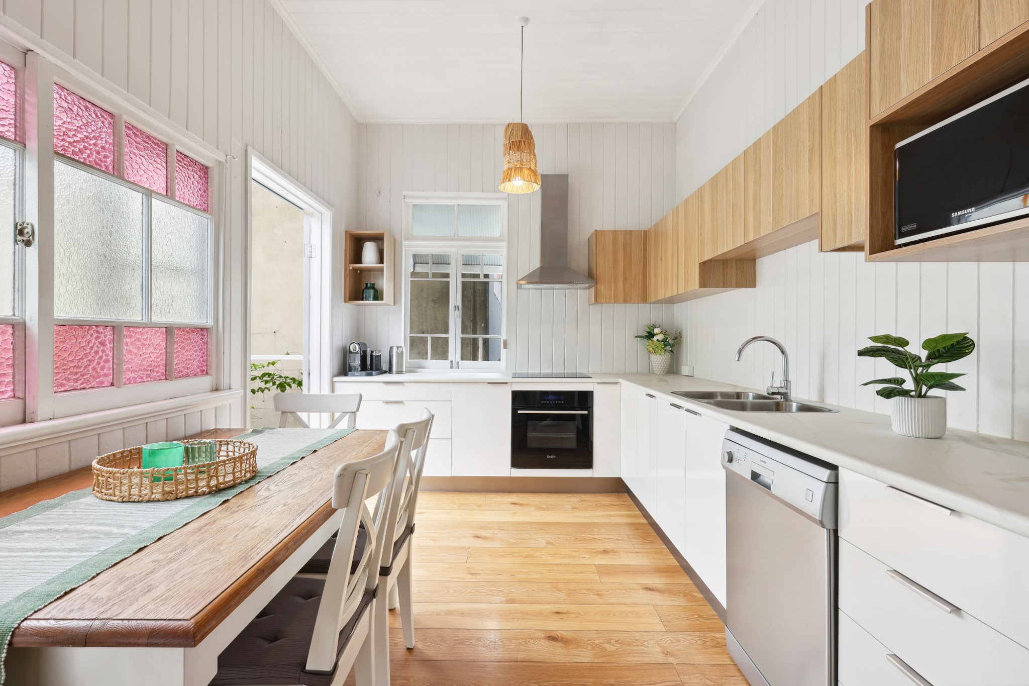 Property description
Stay in this idyllic 3-bed family home in the exciting suburb of Nundah, a 20-min drive from Brisbane's CBD. Close to Oxenham Park, cafes, restaurants, pubs, and shops, this pristine home features bright interiors, white wood walls, and furnishings that contribute to the homely feel you get as soon as stepping into the property. With a spacious pet-friendly backyard and self-check-in, this house will be your home during your stay.

The space
Featuring spacious and bright interiors, this family home is a gem located in the heart of charming Nundah. With timber floors, white wood walls, and large windows that allow sunlight in seamlessly, the home offers a comfy living room, an ample kitchen and dining area, an alfresco dining area on the deck directly outside the kitchen, three elegant bedrooms, and one sleek bathroom with a walk in shower. To help you cool off on a hot day, there is air conditioning in the living area, and ceiling fans in the bedrooms. If you're a proud pet owner, you're in luck! This house presents a large backyard, and pets are welcome to stay here, too. Close to a park and the train station, you'll be within walking distance to Nundah's Village, where you'll find shops, cafes, and restaurants. Don't miss out on this incredible property!