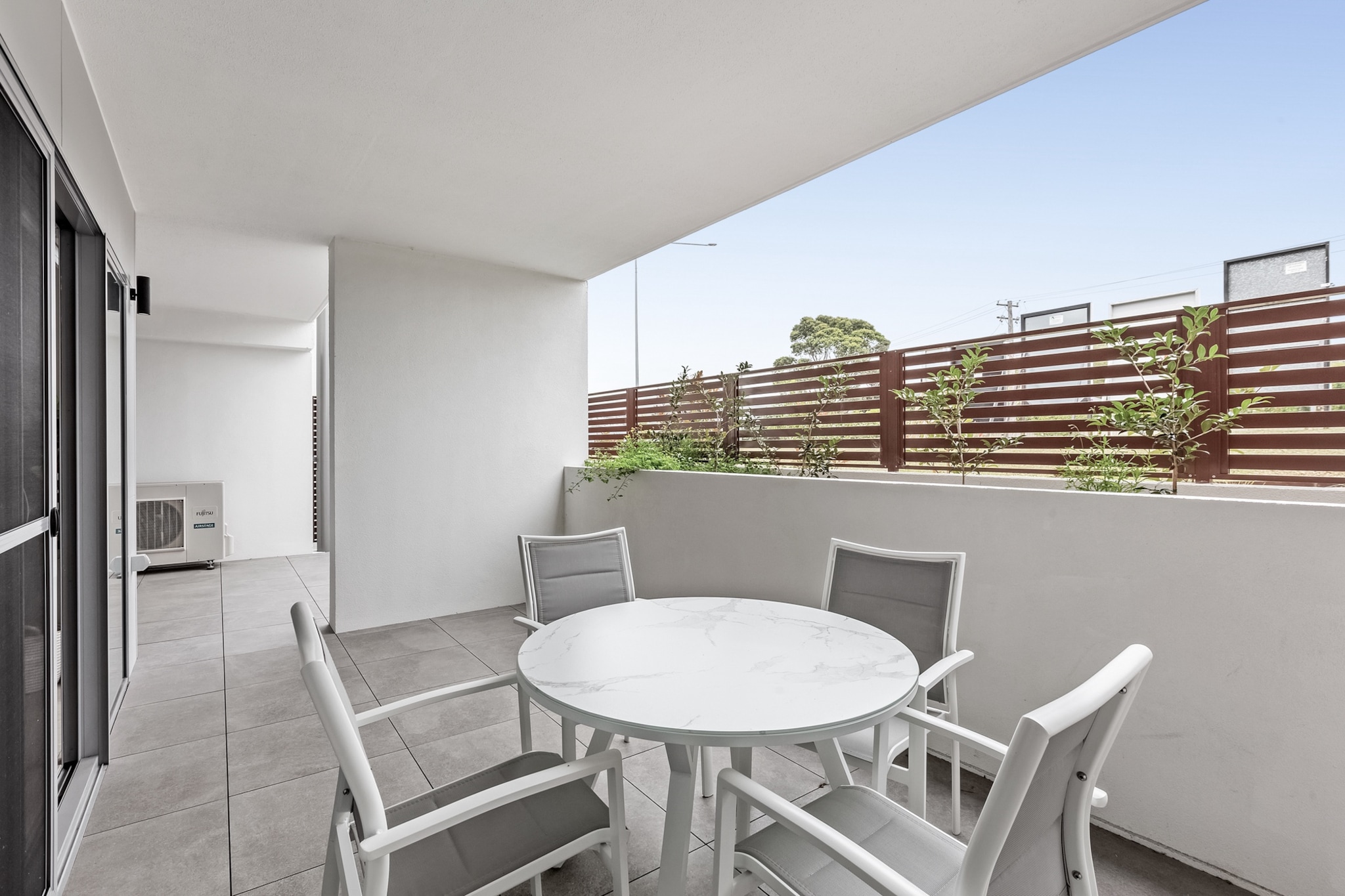 Be amongst the first people to experience Kiama's relaxed atmosphere in this stunning ground floor unit featuring brand new interiors, heaps of space, and proximity to parks, amenities, transport and multiple beaches across NSW's beautiful South Coast. With central A/C, on-site parking and easy access to Kiama's main attractions, this property is ready for your visit.
The space
This brand-new and sparkling property has been designed with elegance, soft finishings, and spacious interiors that are ideal for recharging and relaxing. With a seamless open-plan layout for both dining and living, the home features light timber floors, a tucked-away kitchen with modern appliances, 3 gorgeous bedrooms with built-in robes and large windows, 2 sophisticated bathrooms with walk-in showers, and a private undercover balcony with alfresco dining overlooking the property's leafy grounds. Within walking distance to local restaurants, cafes and shops, you'll be only a few minutes drive from paradise-like locations like Loves Bay, Eats Beach, Little Blowhole, Kendalls Beach and, of course, Kiama Surf Beach.
Living room
- Couch sits 4 people & 2 additional arm chairs
- TV with free air channels and streaming apps (guest to use own credentials)
Kitchen & Dining Area
- Equipped with utensils and cutlery
- Oven and gas stovetop
- Dining area sits 6 people & 2 additional bar stools
Bathroom & Laundry
- Laundry room available with washer and dryer
- Travel essentials, towels and hairdryer provided
Amenity Notes
- Ground floor
- Ducted A/C (heating + cooling) throughout
- Wi-Fi available
- The building and unit are wheelchair accessible
- Garage parking for 2 vehicles
- BBQ is available
- Amenity access: private undercover balcony with alfresco dining overlooking garden
Local area description
Kiama is a picturesque coastal town in the Illawarra region of New South Wales. Known for its stunning landscapes, it's famous for the Kiama Blowhole — a natural rock formation where seawater shoots up into the air, creating an impressive display. The town offers lush greenery, beautiful beaches like Surf Beach and Jones Beach, and coastal walks with breathtaking views of the Pacific Ocean. Kiama exudes a relaxed atmosphere, with a charming town centre featuring cafes, boutique shops, and a friendly community vibe. With its blend of natural beauty and coastal charm, Kiama is a sought-after destination for tourists and locals seeking a tranquil seaside retreat.
House rules
You are staying in a friendly and peaceful neighbourhood and we kindly ask you to respect the community and your surrounding neighbours. The following strict House Rules apply:
- No loud noise between 10 pm and 8 am
- No parties or antisocial behaviour
- No additional people are to access the property without our prior approval
- No smoking is allowed at any times
- If you break something, please let us know
- Pets are allowed upon request, Please note that an additional cleaning fee of AUD 200 will apply for stays with pets.
- No skateboards or scooters allowed within the building premises including parking lot
- To help protect all floor coverings, do not wear any shoes inside the property
Please be aware that excessive noise such as amplified music, vocals or screaming or anti-social behaviour in the property or common areas can cause neighbours to complain to us, the Building Manager, Council Rangers or Police.
IMPORTANT:
- Any breach of the House Rules may lead to a $500 fine plus compensation for any cost/damage created and immediate eviction of the property without refund.
Finally, when checking out, we kindly ask you for the following:
- Please leave all beds unmade
- Please clean up your dishes and put them away
- In case you have rearranged furniture, please put it back to the original location
- Please take out the rubbish and remember to use the right bins
- Please ensure all appliances, A/C and lights are off and doors and windows are closed.
- Please check your accommodation thoroughly before departing to avoid any unintentional items left behind.
We are not liable for any items left behind after your stay. In the rare event that a guest reports a missing item, we will make every effort to locate it for you, but we cannot guarantee its retrieval. If the item is found, we will gladly assist in arranging its return to an address within Australia, subject to postage and service fees.
Important Notice: Garage Security Alert
To ensure everyone's safety, we kindly ask you to follow these precautions during your stay:
- Be Vigilant: If you see anyone in the garage whom you do not recognise, remain aware of your surroundings and proceed with caution.
- Access Control: Do not allow unknown vehicles to follow you into the garage. If another car approaches while you are entering, ensure they have the appropriate access before proceeding.
- Walking Through the Garage: Remain observant when walking through the garage, especially if you notice unfamiliar individuals.
- Security Cameras: Our cameras are being upgraded, but not all areas are covered at this time. Please stay alert and take precautions.
- Reporting Issues: If you notice anything suspicious or if something is missing, please file a police report and inform Building Management immediately.
We appreciate your cooperation in helping maintain a safe and secure environment for everyone. Thank you for your understanding.
Interaction with guests
Welcome to MadeComfy! Our local team curates stays in exceptional Australian & New Zealand properties, ensuring style, comfort, and prime locations for discerning guests. We prioritise your needs to provide a memorable home-away-from-home experience. Explore our digital guidebooks for local recommendations, and don't hesitate to contact us throughout your stay. We're here to ensure your comfort – enjoy your stay with MadeComfy.
Notes
- For your comfort, this property is prepared with professional-grade hotel-style linen, including a three-sheet setup, ensuring a fresh and hygienic sleep experience.
- E-bikes shouldn't be charged overnight or left on without supervision.
Pet Rules:
- We only welcome small to medium-sized pets upon request, additional fees apply.
- Guests are required to contact the host and provide a picture of their pet prior to arrival.
Extra Services:
- Early Check-in: Our standard check-in is at 3 pm. To guarantee early access to the property we suggest booking the night before if available. Otherwise, early check-in is subject to availability from the night before at an additional cost.
- Late check-out: Our standard check-out is at 10 am. To guarantee a later check-out of the property we suggest booking an additional night if available. Otherwise, a late check-out is subject to availability from the night before to an additional cost.
- Baggage: For security reasons, we are unable to receive or to keep unattended baggage before check-in or after check-outf
- We provide a small welcome amenity pack to get your stay started
Important Notice: Garage Security Alert
To ensure everyone's safety, we kindly ask you to follow these precautions during your stay:
- Be Vigilant: If you see anyone in the garage whom you do not recognise, remain aware of your surroundings and proceed with caution.
- Access Control: Do not allow unknown vehicles to follow you into the garage. If another car approaches while you are entering, ensure they have the appropriate access before proceeding.
- Walking Through the Garage: Remain observant when walking through the garage, especially if you notice unfamiliar individuals.
- Security Cameras: Our cameras are being upgraded, but not all areas are covered at this time. Please stay alert and take precautions.
- Reporting Issues: If you notice anything suspicious or if something is missing, please file a police report and inform Building Management immediately.
We appreciate your cooperation in helping maintain a safe and secure environment for everyone. Thank you for your understanding.
- This booking is protected with coverage for lost baggage and emergency medical expenses, provided by Travel Support with claim upto 500 AUD (T&C Applies). For more details reach out to Guest Support team post booking.
Access description
- Self-check in will happen on site. Further details will be provided 3 days before check-in if your booking is successfully reserved.
Getting around
Public transport
The closest bus stop is located 1 km from the property on Hillview Cct after Stewart Pl. Please visit Transport NSW website for more information.
Getting There
The property is located 20 km away from Shellharbour Airport. By car, the journey will take around 20 minutes. By public transportation, the journey will take around 1 hour and 20 minutes.