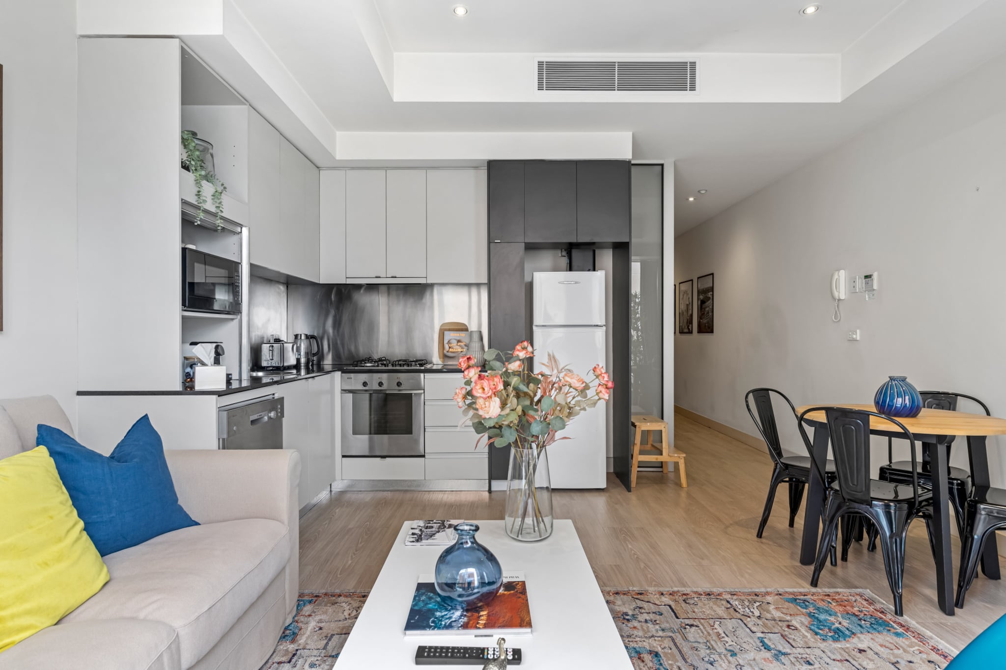 Experience Melbourne's vibrancy in this sophisticated 2-bed CBD apartment, mere meters away from everything this metropolitan haven has to offer. The contemporary space showcases bright interiors, comfortable bedrooms, and a polished bathroom. With a top-notch location, you'll be close to shopping, dining, public transport, and many of the city's iconic sights like the Yarra River, Royal Botanic Gardens, and Fitzroy Gardens. Enjoy your trip from this property in the heart of the city.
The space
Nestled in the city centre, this remarkable 2-bed abode epitomizes modern elegance and prime location. Showcasing Melbourne's breathtaking skyline from a private balcony with seating, this urban haven boasts a welcoming open-plan living area, two stylish bedrooms, and a sophisticated bathroom featuring a polished shower over bath. Ideal for tourists and business travelers, the unit offers air conditioning, seamless self-check-in, and convenient access to Melbourne's dining scene, shopping precincts, and iconic attractions.
 
Living room
- Couch sits 3 people
- Smart TV with free air channels and streaming apps available
 
Kitchen & Dining Area
- Equipped with utensils and cutlery
- Oven and gas stovetop
- Dining area sits 4 people
 
Bathroom & Laundry
- Laundry room available with washer and dryer
- Travel essentials, towels and hairdryer provided
 
Amenity Notes
- Wall-mounted A/C in living area
- Portable fan available in bedroom
- Wi-Fi available
- Amenity access: private balcony with seating
- No secure parking available on the property
Local area description
Melbourne CBD is the central and bustling urban core known for its iconic landmarks like Federation Square, Flinders Street Station, and the Royal Exhibition Building. This vibrant area boasts an array of cultural attractions, including the National Gallery of Victoria and the State Library of Victoria, along with diverse shopping districts such as Bourke Street Mall. With its excellent transportation links at Flinders Street Station, the CBD serves as a key hub for trains, trams, and buses. Additionally, it houses many businesses, government offices, and prestigious universities like RMIT and the University of Melbourne. The Melbourne CBD is a lively epicentre of culture, commerce, and activity in this dynamic Australian city.
House rules
You are staying in a friendly and peaceful neighbourhood and we kindly ask you to respect the community and your surrounding neighbours. The following strict House Rules apply:
 
- No loud noise between 10 pm and 8 am
- No parties or antisocial behaviour
- No additional people are to access the property without our prior approval
- No pets are allowed in the property without approval
- No smoking is allowed at any times
- If you break something, please let us know
- To help protect all floor coverings, do not wear any shoes inside the property
 
Please be aware that excessive noise such as amplified music, vocals or screaming or anti-social behaviour in the property or common areas can cause neighbours to complain to us, the Building Manager, Council Rangers or Police.
 
IMPORTANT:
- Any breach of the House Rules may lead to a $500 fine plus compensation for any cost/damage created and immediate eviction of the property without refund.
- Pets are available on request unless the property states it is pet friendly. Any stays with pets will incur an additional cleaning fee of $200.
 
Finally, when checking out, we kindly ask you for the following:
 
- Please leave all beds unmade
- Please clean up your dishes and put them away
- In case you have rearranged furniture, please put it back to the original location
- Please take out the rubbish and remember to use the right bins
- Please ensure all appliances, A/C and lights are off and doors and windows are closed.
- Please check your accommodation thoroughly before departing to avoid any unintentional items left behind.
 
We are not liable for any items left behind after your stay. In the rare event that a guest reports a missing item, we will make every effort to locate it for you, but we cannot guarantee its retrieval. If the item is found, we will gladly assist in arranging its return to an address within Australia, subject to postage and service fees.
Interaction with guests
Welcome to MadeComfy! Our local team curates stays in exceptional Australian & New Zealand properties, ensuring style, comfort, and prime locations for discerning guests. We prioritise your needs to provide a memorable home-away-from-home experience. Explore our digital guidebooks for local recommendations, and don't hesitate to contact us throughout your stay. We're here to ensure your comfort – enjoy your stay with MadeComfy.
Notes
For your comfort, this property is prepared with professional-grade hotel-style linen, including a three-sheet setup, ensuring a fresh and hygienic sleep experience.
 
Extra Services:
- Early Check-in: Our standard check-in is at 3 pm. To guarantee early access to the property we suggest booking the night before if available. Otherwise, early check-in is subject to availability from the night before at an additional cost.
- Late check-out: Our standard check-out is at 10 am. To guarantee a later check-out of the property we suggest booking an additional night if available. Otherwise, a late check-out is subject to availability from the night before to an additional cost.
- Baggage: For security reasons, we are unable to receive or to keep unattended baggage before check-in or after check-out
- We provide a small welcome amenity pack to get your stay started
- This booking is protected with coverage for lost baggage and emergency medical expenses, provided by Travel Support with claim upto 500 AUD (T&C Applies). For more details reach out to Guest Support team post booking.
Access description
- The key collection is located offsite, 500 meters from the property and not available 24/7. Further details will be provided 3 days before check-in if your booking is successfully reserved.
Getting around
Public transport
The closest bus stop is located 110 m from the property on Melbourne Town Hall/Collins St. The closest tram stop is located 12 m from the property on 6-Melbourne Town Hall/Collins St. Please visit Transport Victoria's website for more information.
 
Getting There
The property is located 25 km away from Melbourne Airport.
By car, the journey will take around 35 minutes. By public transportation, the journey will take around 55 minutes.