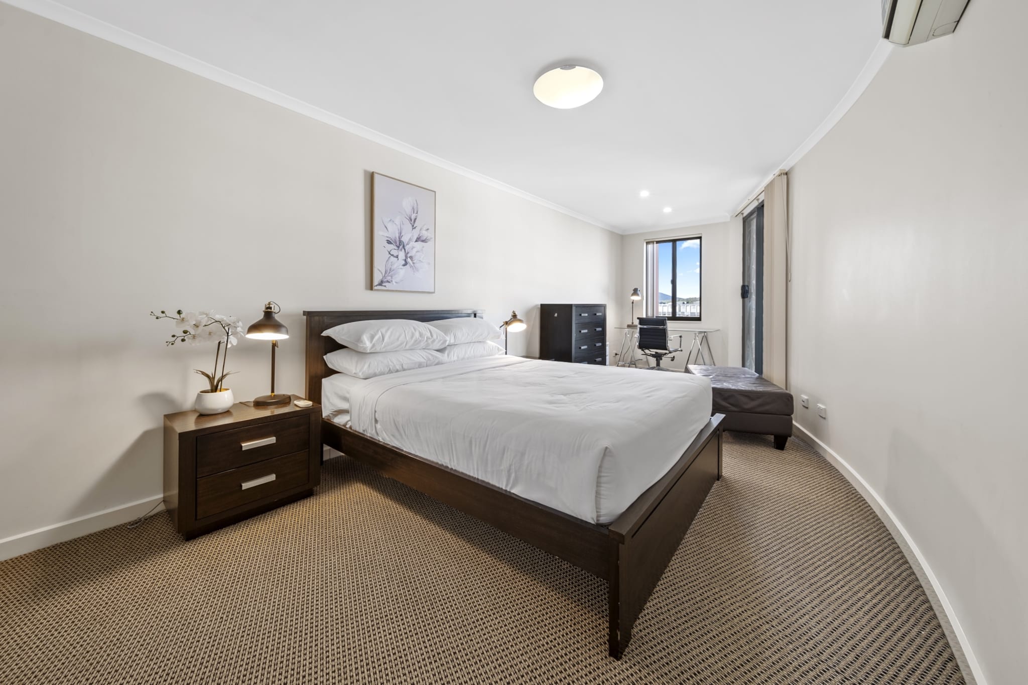 Nestled in trendy Braddon, a short 7-min drive from the CBD, this 2-bed apartment boasts brightness, spaciousness, and convenient proximity to parks, restaurants, and public transport. Thoughtfully designed, the property showcases a radiant, open-plan layout with inviting rooms and a generous balcony with alfresco dining. Complete with air conditioning, on-site parking, and incredible amenities such as pool and gym, prepare yourself for a fantastic experience in this lively and diverse suburb.
The space
Set in the vibrant suburb of Braddon, this elevated apartment promises brightness, spaciousness, and an ideal location to explore the best of the ACT. Offering large balcony doors framing panoramic landscape views, this property boasts an open-plan layout comprising living and dining areas, a sleek kitchen, two queen-sized bedrooms, a designated office space, two polished bathrooms, and a private balcony for outdoor dining. With its proximity to parks, restaurants, shops, and public transport, this pristine apartment provides additional conveniences such as air conditioning, an internal laundry, on-site parking for two cars, and outstanding building facilities such as a swimming pool, a gym and a BBQ area. With the ease of self-check-in, this pristine property promises a hassle-free experience for guests.
 
Living room
- Couch sits 4 people
- TV with streaming apps available
 
Kitchen & Dining Area
- Fully equipped with utensils and cutlery
- Oven and electric stovetop
- Dining area sits 4 people and countertop area sits 2 people
 
Bathroom & Laundry
- Laundry room available with washer and dryer
- Travel essentials, towels and hairdryer provided
 
Amenity Notes
- Split A/C (heating + cooling) in living area and main bedroom
- Wi-Fi available
- Underground parking for 2 standard vehicles
- Amenity access: private balcony with al fresco dining; communal BBQ area, outdoor swimming pool, and gym
Local area description
Braddon is a trendy and vibrant suburb located in the heart of Canberra. Renowned for its eclectic atmosphere, Braddon has undergone significant urban revitalisation in recent years, transforming into a hip and cosmopolitan area. Known for its diverse range of cafes, restaurants, boutiques, and art spaces, Braddon attracts a young and dynamic demographic. The suburb's streets are lined with contemporary apartment buildings, historic cottages, and modern developments, creating a unique urban landscape. Its central location, just north of the Canberra city centre, makes it a popular choice with a lively blend of cultural experiences, culinary delights, and a thriving community spirit.
House rules
You are staying in a friendly and peaceful neighbourhood and we kindly ask you to respect the community and your surrounding neighbours. The following strict House Rules apply:
 
- No loud noise between 10 pm and 8 am
- No parties or antisocial behaviour
- No additional people are to access the property without our prior approval
- No pets are allowed in the property without approval
- No smoking is allowed at any times
- If you break something, please let us know
- To help protect all floor coverings, do not wear any shoes inside the property
 
Please be aware that excessive noise such as amplified music, vocals or screaming or anti-social behaviour in the property or common areas can cause neighbours to complain to us, the Building Manager, Council Rangers or Police.
 
IMPORTANT:
- Any breach of the House Rules may lead to a $500 fine plus compensation for any cost/damage created and immediate eviction of the property without refund.
- Pets are available on request unless the property states it is pet friendly. Any stays with pets will incur an additional cleaning fee of $200.
 
Finally, when checking out, we kindly ask you for the following:
 
- Please leave all beds unmade
- Please clean up your dishes and put them away
- In case you have rearranged furniture, please put it back to the original location
- Please take out the rubbish and remember to use the right bins
- Please ensure all appliances, A/C and lights are off and doors and windows are closed.
- Please check your accommodation thoroughly before departing to avoid any unintentional items left behind.
 
We are not liable for any items left behind after your stay. In the rare event that a guest reports a missing item, we will make every effort to locate it for you, but we cannot guarantee its retrieval. If the item is found, we will gladly assist in arranging its return to an address within Australia, subject to postage and service fees.
Interaction with guests
Welcome to MadeComfy! Our local team curates stays in exceptional Australian & New Zealand properties, ensuring style, comfort, and prime locations for discerning guests. We prioritise your needs to provide a memorable home-away-from-home experience. Explore our digital guidebooks for local recommendations, and don't hesitate to contact us throughout your stay. We're here to ensure your comfort – enjoy your stay with MadeComfy.
Notes
- For your comfort, this property is prepared with professional-grade hotel-style linen, including a three-sheet setup, ensuring a fresh and hygienic sleep experience.
-Terrace and BBQ available on level 4.
 
Extra Services:
- Early Check-in: Our standard check-in is at 3 pm. To guarantee early access to the property we suggest booking the night before if available. Otherwise, early check-in is subject to availability from the night before at an additional cost.
- Late check-out: Our standard check-out is at 10 am. To guarantee a later check-out of the property we suggest booking an additional night if available. Otherwise, a late check-out is subject to availability from the night before to an additional cost.
- Baggage: For security reasons, we are unable to receive or to keep unattended baggage before check-in or after check-out
- We provide a small welcome amenity pack to get your stay started.
- This booking is protected with coverage for lost baggage and emergency medical expenses, provided by Travel Support with claim upto 500 AUD (T&C Applies). For more details reach out to Guest Support team post booking.
Access description
- The key collection is located in a lockbox offsite, 600 meters from the property. Further details will be provided 3 days before check-in if your booking is successfully reserved.
Getting around
Public transport
The closest light rail station is located 350 m from the property on Elouera Street. The closest bus stop is located 400 m away from the property on Northbourne Ave Mantra. Please visit Transport Canberra website for more information.
 
Getting There
The property is located 8 km away from Canberra Airport. By car, the journey will take around 15 minutes. By public transportation, the journey will take around 50 minutes.