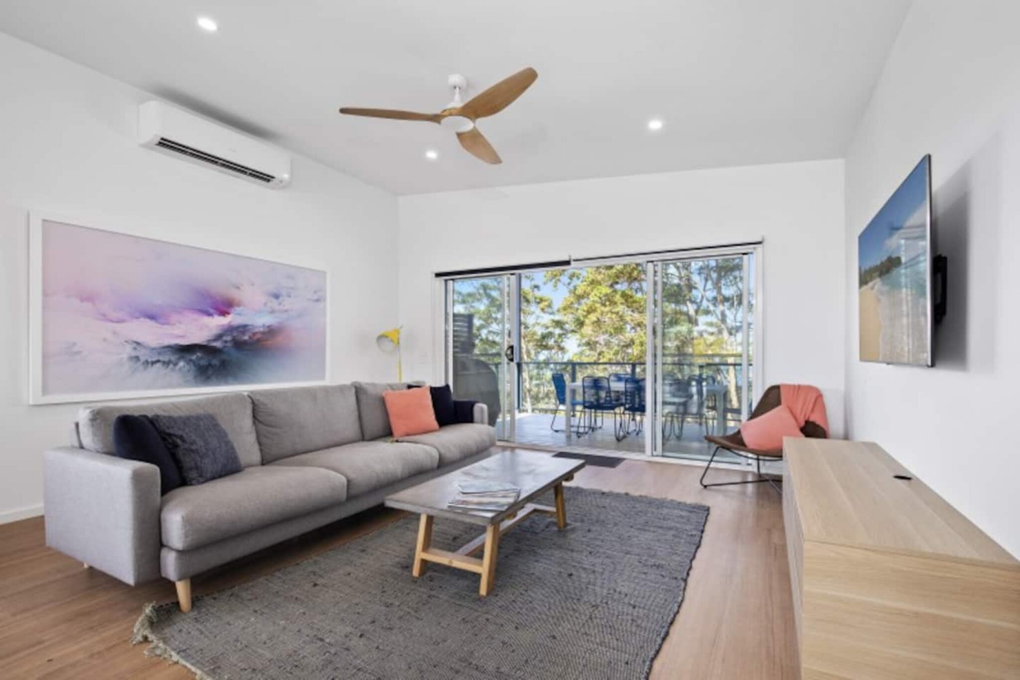 Experience a perfect coastal getaway in this modern split-level home, moments from Long Beach and local shops. With two large decks offering stunning views of Long Beach and surrounding bushland, it's ideal for outdoor entertainment. The house includes two queen beds, a room with two bunk beds, and ample outdoor dining space. It's pet-friendly and offers direct access to a dog-friendly beach via a path at the back, where you can hear the waves from the house.
The space
Situated just moments from Long Beach and local shops, this modern split-level home is the perfect coastal getaway, especially for families with children. It features expansive outdoor entertaining spaces, including two large decks with stunning views of Long Beach and the surrounding bushland. The house has two queen beds, a room with two bunk beds, and ample outdoor dining space. It is also pet-friendly and so close to the beach that you can hear the waves. A convenient path at the back provides easy access to the sandy, dog-friendly shore, offering a fantastic spot for relaxation and play.
 
Living room
- Couch seats 6 people
- TV with free air channels and streaming apps available (to be used with guest's accounts)
 
Kitchen & Dining Area
- Fully equipped with utensils and cutlery
- Oven and stovetop
- Dining area sits 8 people & 2 seats at the countertop
 
Bathroom & Laundry
- Laundry room available with washer and dryer
- Travel essentials, towels and hairdryer
 
Amenity Notes
- Split A/C (heating + cooling) in living area/dining area
- Ceiling fans in bedrooms and living/dining area
- Wi-Fi available
- Parking for 1 medium- to large car
- Amenity access: private balcony with alfresco dining and BBQ
- Access to the beach, fire pit area and outdoor shower
Local area description
Batemans Bay, nestled on the stunning south coast of New South Wales, embodies a harmonious blend of coastal charm and natural beauty. As the region's commercial hub, it offers a picturesque waterfront embraced by pristine beaches, including the popular Surfside and Catalina. The Clyde River, weaving through the town, provides a serene backdrop for leisurely activities such as fishing, boating, and kayaking. Its vibrant community celebrates diverse events, from local markets showcasing regional produce to cultural festivals. With its proximity to Murramarang National Park and Eurobodalla National Park, Batemans Bay beckons nature enthusiasts with opportunities for bush walks, wildlife spotting, and breathtaking scenic lookouts. The town's relaxed ambience, coastal allure, and abundant outdoor pursuits, makes it a captivating destination for residents and tourists.
House rules
You are staying in a friendly and peaceful neighbourhood and we kindly ask you to respect the community and your surrounding neighbours. The following strict House Rules apply:
 
- No loud noise between 10 pm and 8 am
- No parties or antisocial behaviour
- No additional people are to access the property without our prior approval
- No smoking is allowed at any times
- If you break something, please let us know
- To help protect all floor coverings, do not wear any shoes inside the property
 
Please be aware that excessive noise such as amplified music, vocals or screaming or anti-social behaviour in the property or common areas can cause neighbours to complain to us, the Building Manager, Council Rangers or Police.
 
IMPORTANT:
- Any breach of the House Rules may lead to a $500 fine plus compensation for any cost/damage created and immediate eviction of the property without refund.
- Pets are available on request unless the property states it is pet friendly. Any stays with pets will incur an additional cleaning fee of $200.
 
Finally, when checking out, we kindly ask you for the following:
 
- Please leave all beds unmade
- Please clean up your dishes and put them away
- In case you have rearranged furniture, please put it back to the original location
- Please take out the rubbish and remember to use the right bins
- Please ensure all appliances, A/C and lights are off and doors and windows are closed.
- Please check your accommodation thoroughly before departing to avoid any unintentional items left behind.
 
We are not liable for any items left behind after your stay. In the rare event that a guest reports a missing item, we will make every effort to locate it for you, but we cannot guarantee its retrieval. If the item is found, we will gladly assist in arranging its return to an address within Australia, subject to postage and service fees.
Interaction with guests
Welcome to MadeComfy! Our local team curates stays in exceptional Australian & New Zealand properties, ensuring style, comfort, and prime locations for discerning guests. We prioritise your needs to provide a memorable home-away-from-home experience. Explore our digital guidebooks for local recommendations, and don't hesitate to contact us throughout your stay. We're here to ensure your comfort – enjoy your stay with MadeComfy.
Notes
- For your comfort, this property is prepared with professional-grade hotel-style linen, including a three-sheet setup, ensuring a fresh and hygienic sleep experience.
- Pets are welcome. Any stays with pets will incur an additional cleaning fee.
 
Extra Services:
- Early Check-in: Our standard check-in is at 3 pm. To guarantee early access to the property we suggest booking the night before if available. Otherwise, early check-in is subject to availability from the night before at an additional cost.
- Late check-out: Our standard check-out is at 10 am. To guarantee a later check-out of the property we suggest booking an additional night if available. Otherwise, a late check-out is subject to availability from the night before to an additional cost.
- Baggage: For security reasons, we are unable to receive or to keep unattended baggage before check-in or after check-out
- We provide a small welcome amenity pack to get your stay started.
- This booking is protected with coverage for lost baggage and emergency medical expenses, provided by Travel Support with claim upto 500 AUD (T&C Applies). For more details reach out to Guest Support team post booking.
Access description
- The key collection is located onsite. Further details will be provided 3 days before check-in if your booking is successfully reserved.
Getting around
The journey time between Sydney and Long Beach is around 7h 35m and covers a distance of around 403 km. This includes an average layover time of around 2h. Operated by NSW TrainLink, Murrays Coaches and Priors Bus Service, the Sydney to Long Beach service departs from Central Station and arrives in Northcove Beach Rd At Maloneys Dr. Typically 11 services run weekly, although weekend and holiday schedules can vary so check in advance. Please visit Transport NSW website for more information.
 
Getting There
The property is located 37 km away from Moruya Airport. By car, the journey will take around 35 minutes.