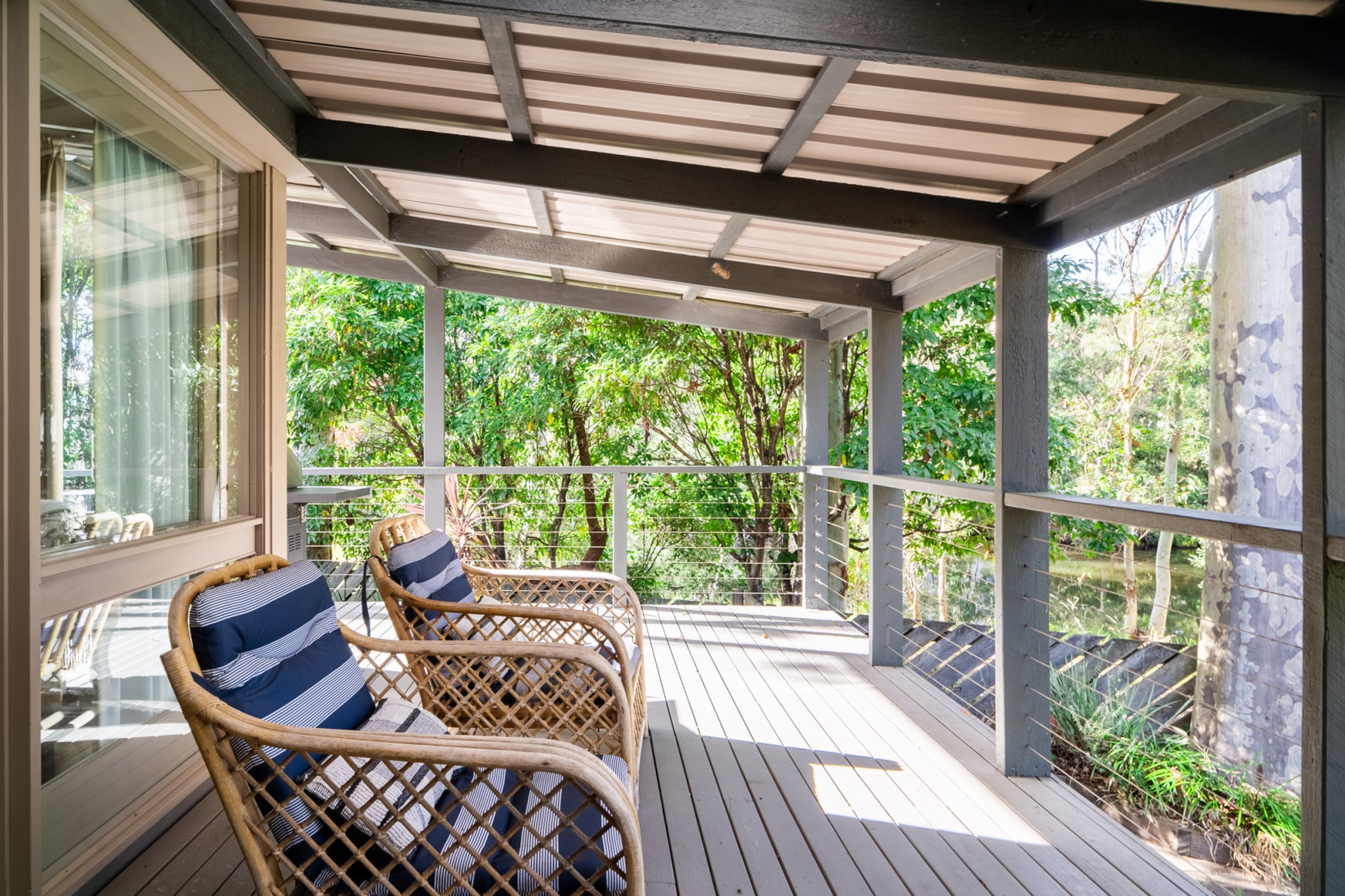 Discover serenity at this spacious 3-bedroom, 2-bathroom haven bordering a picturesque estuary that meets the sea at Wimbie Beach, just seconds away. Ideal for families, this stunning retreat offers a range of relaxing and adventurous activities. Snuggle up on the large couch by the fireplace, unwind in the grassy backyard to the soothing sounds of the ocean, or explore the nearby breathtaking walking tracks. The Saltbush is your perfect escape for a relaxing and adventurous coastal escape.
The space
This chic beachside home is a haven of tranquillity, offering an expansive open-plan kitchen, living, and dining area where you can relax year-round. Whether you're cuddled up near the fireplace or enjoying the cool breeze through the open doors, there's ample space for the whole family. On sunny mornings or warm afternoons, step out onto the wrap-around veranda, grab a seat overlooking the grassy backyard, or gather around the outdoor fire pit. The soothing sounds of crashing waves from Wimbie Beach and the gentle activity of the nearby estuary create a serene backdrop, enhancing the sense of seclusion. The 3 bedrooms include a queen room, a kids' room with 2 single beds, and a third room with 2 queen beds and an en-suite with a separate bath and shower. All rooms offer a peaceful, leafy view and ample space for your belongings. For a serene South Coast getaway, the Saltbush provides a perfect blend of comfort, nature, and privacy.
Living room
- Couch seats 6 people
- TV with free air channels and streaming apps available (to be used with guest's accounts)
Kitchen & Dining Area
- Fully equipped with utensils and cutlery
- Oven and electric stovetop
- Dining area sits 6 people
Bathroom & Laundry
- Laundry room available with washer
- Travel essentials, towels and hairdryer
Amenity Notes
- Split A/C (heating + cooling) in living area
- Portable fan and heater
- Fireplace
- Wi-Fi available
- Parking onsite
- Amenity access: Private veranda, outdoor area with firepit, balcony area with seating
Local area description
Bateman’s Bay is a 10-minute drive north of Surf beach and has everything else you need including larger supermarkets and other facilities. Just a short drive north or south of Surf Beach and you will be spoilt for choice with gorgeous bush walks, stunning beaches and quaint beachside towns. You can explore until your heart's content. Mogo wildlife park is about 15-minute drive southwest and there’s a BMX track nearby to that as well.
House rules
You are staying in a friendly and peaceful neighbourhood and we kindly ask you to respect the community and your surrounding neighbours. The following strict House Rules apply:
- No loud noise between 10 pm and 8 am
- No parties or antisocial behaviour
- No additional people are to access the property without our prior approval
- No pets are allowed in the property without approval
- No smoking is allowed at any times
- If you break something, please let us know
- To help protect all floor coverings, do not wear any shoes inside the property
Please be aware that excessive noise such as amplified music, vocals or screaming or anti-social behaviour in the property or common areas can cause neighbours to complain to us, the Building Manager, Council Rangers or Police.
IMPORTANT:
- Any breach of the House Rules may lead to a $500 fine plus compensation for any cost/damage created and immediate eviction of the property without refund.
- Pets are available on request unless the property states it is pet friendly. Any stays with pets will incur an additional cleaning fee of $200.
Finally, when checking out, we kindly ask you for the following:
- Please leave all beds unmade
- Please clean up your dishes and put them away
- In case you have rearranged furniture, please put it back to the original location
- Please take out the rubbish and remember to use the right bins
- Please ensure all appliances, A/C and lights are off and doors and windows are closed.
- Please check your accommodation thoroughly before departing to avoid any unintentional items left behind.
We are not liable for any items left behind after your stay. In the rare event that a guest reports a missing item, we will make every effort to locate it for you, but we cannot guarantee its retrieval. If the item is found, we will gladly assist in arranging its return to an address within Australia, subject to postage and service fees.
Interaction with guests
Welcome to MadeComfy! Our local team curates stays in exceptional Australian & New Zealand properties, ensuring style, comfort, and prime locations for discerning guests. We prioritise your needs to provide a memorable home-away-from-home experience. Explore our digital guidebooks for local recommendations, and don't hesitate to contact us throughout your stay. We're here to ensure your comfort – enjoy your stay with MadeComfy.
Notes
- For your comfort, this property is prepared with professional-grade hotel-style linen, including a three-sheet setup, ensuring a fresh and hygienic sleep experience.
- Please note that this property has cameras in the external areas of the property. It is located in a cul-de-sac and alongside a track that leads to the beach. These are purely for security reasons.
Extra Services:
- Early Check-in: Our standard check-in is at 3 pm. To guarantee early access to the property we suggest booking the night before if available. Otherwise, early check-in is subject to availability from the night before at an additional cost.
- Late check-out: Our standard check-out is at 10 am. To guarantee a later check-out of the property we suggest booking an additional night if available. Otherwise, a late check-out is subject to availability from the night before to an additional cost.
- Baggage: For security reasons, we are unable to receive or to keep unattended baggage before check-in or after check-out
- We provide a small welcome amenity pack to get your stay started.
- Firewood is not provided - we recommend purchasing your own.
- This booking is protected with coverage for lost baggage and emergency medical expenses, provided by Travel Support with claim upto 500 AUD (T&C Applies). For more details reach out to Guest Support team post booking.
Access description
The key collection is located onsite. Further details will be provided 3 days before check-in if your booking is successfully reserved.
Getting around
This cosy home is tucked away on a quiet and tranquil street set back from the beautiful Surf Beach. Take the 2-minute drive or 7-minute walk down to the beach where you will find a local pizza shop, IGA, pharmacy, cafe and grassy areas with picnic tables. The beach is patrolled in the peak months and there are toilets and showers. Wimble beach is a sheltered, dog-friendly beach south of Surf Beach, just a few minutes walk from Surf Beach or a 15-minute walk from Highview Avenue. Denhams Beach is the third beautiful bay on the Surf Beach Coast that enjoys the tranquil waters provided by the protective rocky outcrops nearby. North of Surf Beach, Denhams Beach is where the bush meets the sea and is a popular spot for families, snorkelling and beginner surfers.