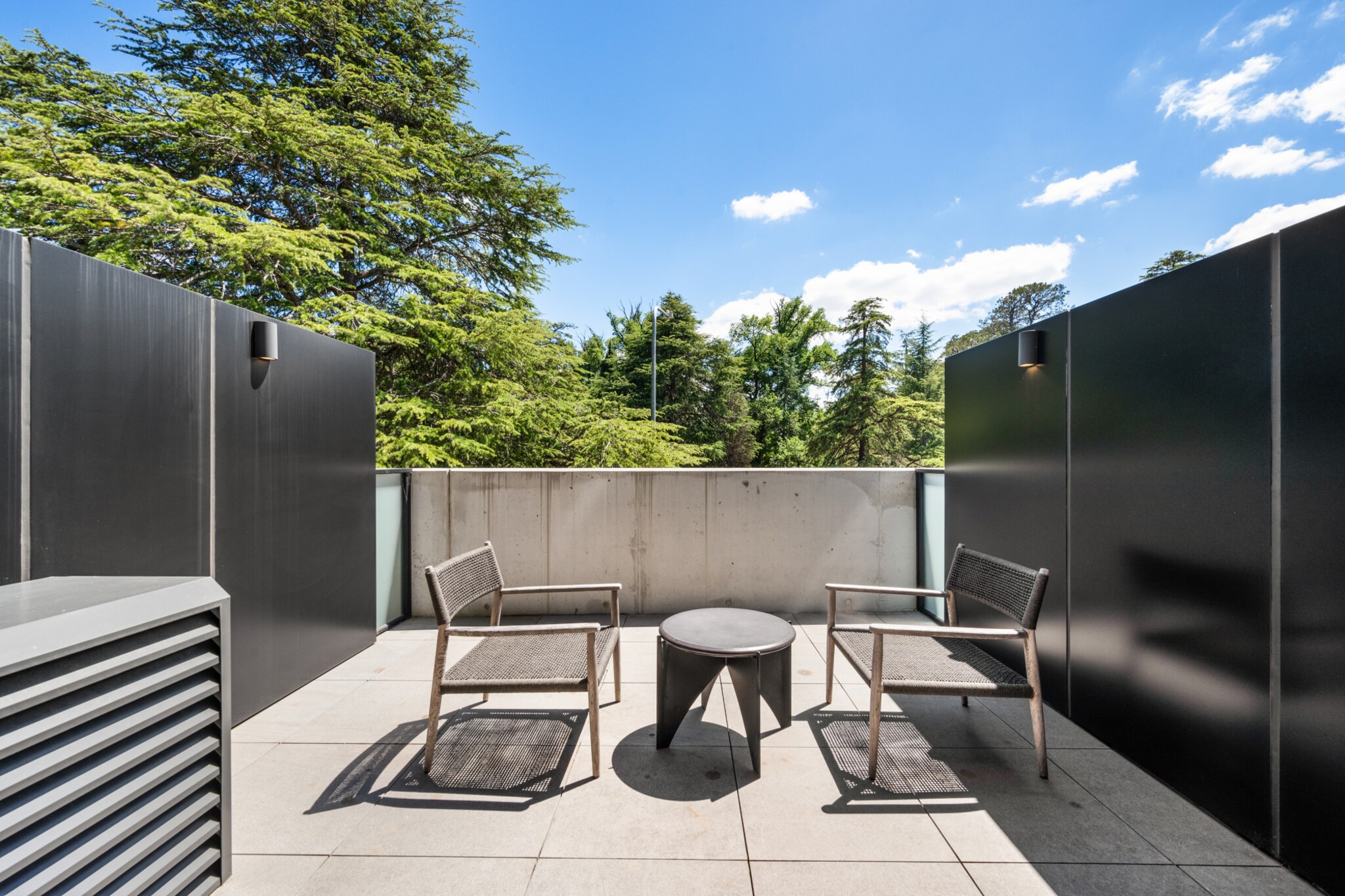 For those visiting the ACT for business or pleasure, this pristine studio offers a perfect blend of elegance and ease. The stylish, light-filled interiors with expansive windows provide a warm and inviting space. Just a short walk from parks, excellent dining options, and public transportation, it ensures a convenient stay. With features like air conditioning, onsite parking, and a location just 7 minutes from the CBD, this accommodation is an excellent choice for your ACT visit.

The space
This elegantly crafted king-sized studio apartment offers a perfect blend of comfort, sophistication, and practicality. Step inside to find a chic, compact kitchen and a spotless, contemporary bathroom. The open and airy design boasts large sliding doors leading to a shared balcony, featuring a BBQ area, dining space, and stunning views. Ideally situated, it provides easy access to parks, restaurants, shops, and public transport. Additional amenities include air conditioning, laundry facilities, and onsite parking. With the convenience of self-check-in, guests are guaranteed a smooth and enjoyable stay in this pristine property.
 
Living Space
- Couch sits 2 people
- TV with free air channels & streaming available (guests to use own credentials)
 
Kitchen & Dining Area
- Fully equipped with cookware, utensils and cutlery
- Oven and induction stovetop
 
Bathroom & Laundry
- Paid communal laundry facilities available
- Travel essentials, towels and hairdryer provided
 
Amenity Notes
- Split A/C (heating + cooling)
- Wi-Fi available
- Parking for 1 vehicle
- Amenity access: access to a communal balcony with a BBQ area, dining area, and views (level 1)
Local area description
Braddon is a trendy and vibrant suburb located in the heart of Canberra. Renowned for its eclectic atmosphere, Braddon has undergone significant urban revitalisation in recent years, transforming into a hip and cosmopolitan area. Known for its diverse range of cafes, restaurants, boutiques, and art spaces, Braddon attracts a young and dynamic demographic. The suburb's streets are lined with contemporary apartment buildings, historic cottages, and modern developments, creating a unique urban landscape. Its central location, just north of the Canberra city centre, makes it a popular choice with a lively blend of cultural experiences, culinary delights, and a thriving community spirit.