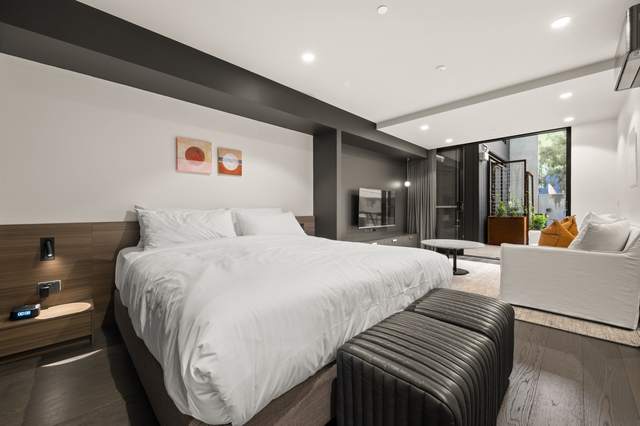 Perfect for business or leisure travelers to the ACT, this pristine studio combines elegance and ease. The bright, contemporary interiors with expansive windows provide a warm and inviting atmosphere. Just steps away, you'll find parks, great restaurants, and public transport options. With air conditioning, onsite parking, and a convenient location only 7 minutes from the CBD, this accommodation is ideal for your ACT visit.
The space
Designed with elegance and comfort in mind, this king-sized studio apartment features a sleek, compact kitchen and a modern, pristine bathroom. The bright and spacious interior boasts large sliding doors that open onto a shared balcony with a BBQ area, dining space, and breathtaking views. Located in a prime area, you'll have convenient access to parks, restaurants, shops, and public transport. Additional amenities include air conditioning, laundry facilities, and onsite parking. With self-check-in available, guests can enjoy a flawless experience from start to finish in this immaculate property.
Living Space
- Couch sits 2 people
- TV with free air channels & streaming available (guests to use own credentials)
Kitchen & Dining Area
- Fully equipped with cookware, utensils and cutlery
- Oven and induction stovetop
Bathroom & Laundry
- Paid communal laundry facilities available
- Travel essentials, towels and hairdryer provided
Amenity Notes
- Split A/C (heating + cooling)
- Wi-Fi available
- Parking for 1 vehicle
- Amenity access: access to a communal balcony with a BBQ area, dining area, and views (level 1)
Local area description
Braddon is a trendy and vibrant suburb located in the heart of Canberra. Renowned for its eclectic atmosphere, Braddon has undergone significant urban revitalisation in recent years, transforming into a hip and cosmopolitan area. Known for its diverse range of cafes, restaurants, boutiques, and art spaces, Braddon attracts a young and dynamic demographic. The suburb's streets are lined with contemporary apartment buildings, historic cottages, and modern developments, creating a unique urban landscape. Its central location, just north of the Canberra city centre, makes it a popular choice with a lively blend of cultural experiences, culinary delights, and a thriving community spirit.
House rules
You are staying in a friendly and peaceful neighbourhood and we kindly ask you to respect the community and your surrounding neighbours. The following strict House Rules apply:
- No loud noise between 10 pm and 8 am
- No parties or antisocial behaviour
- No additional people are to access the property without our prior approval
- No pets are allowed in the property without approval
- No smoking is allowed at any times
- If you break something, please let us know
- To help protect all floor coverings, do not wear any shoes inside the property
Please be aware that excessive noise such as amplified music, vocals or screaming or anti-social behaviour in the property or common areas can cause neighbours to complain to us, the Building Manager, Council Rangers or Police.
IMPORTANT:
- Any breach of the House Rules may lead to a $500 fine plus compensation for any cost/damage created and immediate eviction of the property without refund.
- Pets are available on request unless the property states it is pet friendly. Any stays with pets will incur an additional cleaning fee of $200.
Finally, when checking out, we kindly ask you for the following:
- Please leave all beds unmade
- Please clean up your dishes and put them away
- In case you have rearranged furniture, please put it back to the original location
- Please take out the rubbish and remember to use the right bins
- Please ensure all appliances, A/C and lights are off and doors and windows are closed.
- Please check your accommodation thoroughly before departing to avoid any unintentional items left behind.
We are not liable for any items left behind after your stay. In the rare event that a guest reports a missing item, we will make every effort to locate it for you, but we cannot guarantee its retrieval. If the item is found, we will gladly assist in arranging its return to an address within Australia, subject to postage and service fees.
Interaction with guests
Welcome to MadeComfy! Our local team curates stays in exceptional Australian & New Zealand properties, ensuring style, comfort, and prime locations for discerning guests. We prioritise your needs to provide a memorable home-away-from-home experience. Explore our digital guidebooks for local recommendations, and don't hesitate to contact us throughout your stay. We're here to ensure your comfort - enjoy your stay with MadeComfy.
Notes
For your comfort, this property is prepared with professional-grade hotel-style linen, including a three-sheet setup, ensuring a fresh and hygienic sleep experience.
Extra Services:
- Early Check-in: Our standard check-in is at 3 pm. To guarantee early access to the property we suggest booking the night before if available. Otherwise, early check-in is subject to availability from the night before at an additional cost.
- Late check-out: Our standard check-out is at 10 am. To guarantee a later check-out of the property we suggest booking an additional night if available. Otherwise, a late check-out is subject to availability from the night before to an additional cost.
- Baggage: For security reasons, we are unable to receive or to keep unattended baggage before check-in or after check-out
- We provide a small welcome amenity pack to get your stay started.
- On level 1, there is a guest laundry with 2 x washers and 2 x dryers, please use your credit card for payment only.
- This booking is protected with coverage for lost baggage and emergency medical expenses, provided by Travel Support with claim upto 500 AUD (T&C Applies). For more details reach out to Guest Support team post booking.
Access description
- To access this property, you must download an app for key access. Note that check-in requires a smartphone & internet capable of downloading the app, and bookings are non-refundable once confirmed. There is no alternative form of access available. Without the app, access to the building cannot be provided. Further details will be provided 3 days before check-in if your booking is successfully reserved.
- The property entry is wheelchair accessible.
Getting around
Public Transport
The light rail runs along Northbourne Avenue, with the closest stop being Elouera Street (550m away). The closest bus stop is located 240 m away from the property on Torrens St after Girrahween St. Please visit the Transport Canberra website for more information.
Getting There
The property is located 8 km away from Canberra Airport. By car, the journey will take around 10 minutes. By public transportation, the journey will take around 40 minutes.