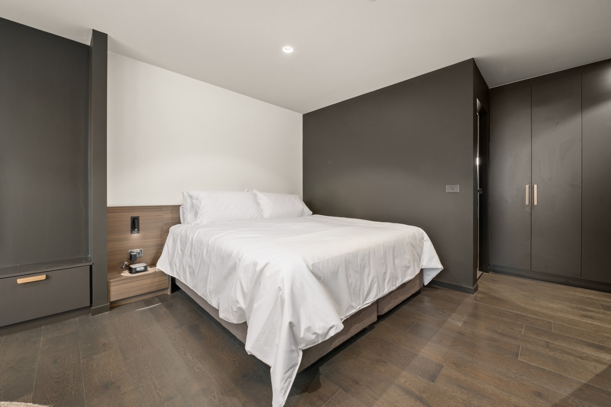 This immaculate studio is designed with elegance and convenience in mind, ideal for both business and leisure travelers to the ACT. Its bright, contemporary interiors and expansive windows create a welcoming atmosphere. Situated near parks, top-notch restaurants, and public transport, it offers amenities such as air conditioning, onsite parking, and a convenient 7-minute drive to the CBD, making it the perfect choice for your stay in the ACT.
The space
Experience comfort, elegance, and functionality in this beautifully designed king-sized studio apartment. Discover a stylish kitchen and modern bathroom within its bright and spacious layout. Large sliding doors open to a communal balcony with BBQ facilities, dining space, and stunning views. Enjoy prime location convenience with parks, restaurants, shops, and public transport nearby. Additional amenities like air conditioning, laundry facilities, onsite parking, and self-check-in ensure a seamless experience in this immaculate property.
Living Space
- Couch sits 2 people
- TV with free air channels & streaming available (guests to use own credentials)
Kitchen & Dining Area
- Fully equipped with cookware, utensils and cutlery
- Oven and induction stovetop
Bathroom & Laundry
- Paid communal laundry facilities available
- Travel essentials, towels and hairdryer provided
Amenity Notes
- Split A/C (heating + cooling)
- Wi-Fi available
- No Parking
- Amenity access: access to a communal balcony with a BBQ area, dining area, and views (level 1)
Local area description
Braddon is a trendy and vibrant suburb located in the heart of Canberra. Renowned for its eclectic atmosphere, Braddon has undergone significant urban revitalisation in recent years, transforming into a hip and cosmopolitan area. Known for its diverse range of cafes, restaurants, boutiques, and art spaces, Braddon attracts a young and dynamic demographic. The suburb's streets are lined with contemporary apartment buildings, historic cottages, and modern developments, creating a unique urban landscape. Its central location, just north of the Canberra city centre, makes it a popular choice with a lively blend of cultural experiences, culinary delights, and a thriving community spirit.