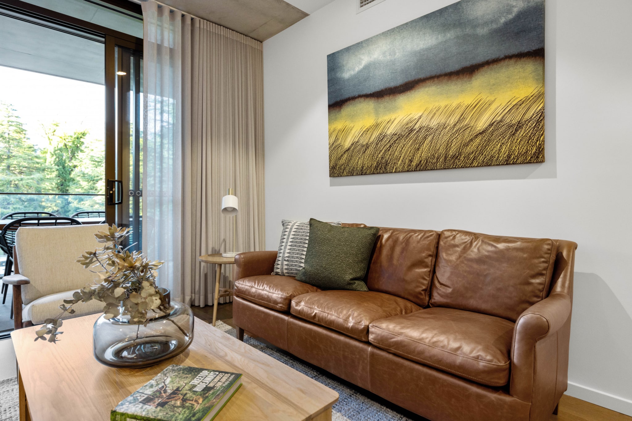 This elegant 2-bed apartment and its sophisticated design match the vibe of trendy Braddon perfectly. Designed to a high standard, this immaculate home offers ample interiors that will make you feel like you found a small piece of heaven. Be stunned by the bright, modern fixtures such as large windows, brand new facilities and impeccable location, putting you nearby parks, restaurants, and public transit. Enjoy amenities such as A/C, onsite parking, and a private alfresco dining balcony.
The space
Step inside this stunning designer 2-bed, 2-bath apartment and be greeted by a bright, spacious layout with large windows that frame beautiful views of the green and urban landscape. The open-plan layout seamlessly combines the living and dining areas with a sleek kitchen, two generous bedrooms, and two spa-like bathrooms featuring rain showers and one bath. Outside, your private balcony is perfect for al fresco dining. The apartment's location is unbeatable, with parks, restaurants, shops, and public transport all nearby, making life easy. Additional conveniences include air conditioning, an internal laundry, and onsite parking. Residents can also enjoy fantastic facilities such as a communal balcony with BBQ and dining areas. With self-check-in available, guests can expect a hassle-free experience from start to finish in this elegant property.
Living room
- Couch seats 4 people
- TV with free air channels & streaming available (guests to use own credentials)
Kitchen & Dining Area
- Fully equipped with cookware, utensils and cutlery
- Oven and induction stovetop
- Dining area sits 4 people + countertop seats 2
Bathroom & Laundry
- Internal laundry with washer and dryer
- Travel essentials, towels and hairdryer provided
Amenity Notes
- Split A/C (heating + cooling)
- Wi-Fi available
- Parking for 1 vehicle
- Amenity access: Private balcony with outdoor dining and access to a communal balcony with a BBQ area, dining area, and views (level 1)
Local area description
Braddon is a trendy and vibrant suburb located in the heart of Canberra. Renowned for its eclectic atmosphere, Braddon has undergone significant urban revitalisation in recent years, transforming into a hip and cosmopolitan area. Known for its diverse range of cafes, restaurants, boutiques, and art spaces, Braddon attracts a young and dynamic demographic. The suburb's streets are lined with contemporary apartment buildings, historic cottages, and modern developments, creating a unique urban landscape. Its central location, just north of the Canberra city centre, makes it a popular choice with a lively blend of cultural experiences, culinary delights, and a thriving community spirit.
House rules
You are staying in a friendly and peaceful neighbourhood and we kindly ask you to respect the community and your surrounding neighbours. The following strict House Rules apply:
- No loud noise between 10 pm and 8 am
- No parties or antisocial behaviour
- No additional people are to access the property without our prior approval
- No pets are allowed in the property without approval
- No smoking is allowed at any times
- If you break something, please let us know
- To help protect all floor coverings, do not wear any shoes inside the property
Please be aware that excessive noise such as amplified music, vocals or screaming or anti-social behaviour in the property or common areas can cause neighbours to complain to us, the Building Manager, Council Rangers or Police.
IMPORTANT:
- Any breach of the House Rules may lead to a $500 fine plus compensation for any cost/damage created and immediate eviction of the property without refund.
- Pets are available on request unless the property states it is pet friendly. Any stays with pets will incur an additional cleaning fee of $200.
Finally, when checking out, we kindly ask you for the following:
- Please leave all beds unmade
- Please clean up your dishes and put them away
- In case you have rearranged furniture, please put it back to the original location
- Please take out the rubbish and remember to use the right bins
- Please ensure all appliances, A/C and lights are off and doors and windows are closed.
- Please check your accommodation thoroughly before departing to avoid any unintentional items left behind.
We are not liable for any items left behind after your stay. In the rare event that a guest reports a missing item, we will make every effort to locate it for you, but we cannot guarantee its retrieval. If the item is found, we will gladly assist in arranging its return to an address within Australia, subject to postage and service fees.
Interaction with guests
Welcome to MadeComfy! Our local team curates stays in exceptional Australian & New Zealand properties, ensuring style, comfort, and prime locations for discerning guests. We prioritise your needs to provide a memorable home-away-from-home experience. Explore our digital guidebooks for local recommendations, and don't hesitate to contact us throughout your stay. We're here to ensure your comfort - enjoy your stay with MadeComfy.
Notes
For your comfort, this property is prepared with professional-grade hotel-style linen, including a three-sheet setup, ensuring a fresh and hygienic sleep experience.
Extra Services:
- Early Check-in: Our standard check-in is at 3 pm. To guarantee early access to the property we suggest booking the night before if available. Otherwise, early check-in is subject to availability from the night before at an additional cost.
- Late check-out: Our standard check-out is at 10 am. To guarantee a later check-out of the property we suggest booking an additional night if available. Otherwise, a late check-out is subject to availability from the night before to an additional cost.
- Baggage: For security reasons, we are unable to receive or to keep unattended baggage before check-in or after check-out
- We provide a small welcome amenity pack to get your stay started.
- This booking is protected with coverage for lost baggage and emergency medical expenses, provided by Travel Support with claim upto 500 AUD (T&C Applies). For more details reach out to Guest Support team post booking.
Access description
- To access this property, you must download an app for key access. Note that check-in requires a smartphone & internet capable of downloading the app, and bookings are non-refundable once confirmed. There is no alternative form of access available. Without the app, access to the building cannot be provided. Further details will be provided 3 days before check-in if your booking is successfully reserved.
Getting around
Public Transport
The light rail runs along Northbourne Avenue, with the closest stop being Elouera Street (550m away). The closest bus stop is located 240 m away from the property on Torrens St after Girrahween St. Please visit the Transport Canberra website for more information.
Getting There
The property is located 8 km away from Canberra Airport. By car, the journey will take around 10 minutes. By public transportation, the journey will take around 40 minutes.