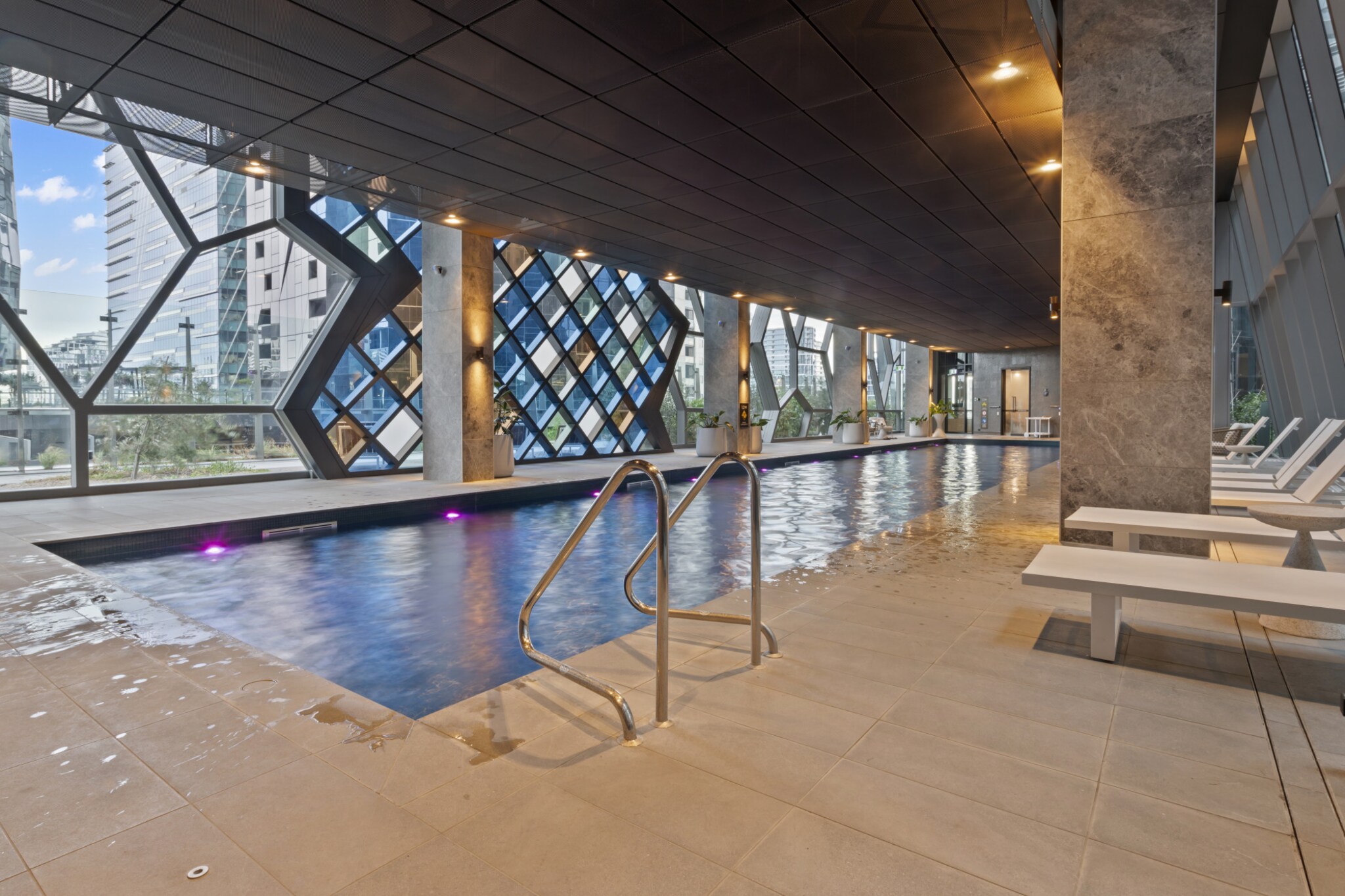 Chic 2-Bed Melbourne CBD Apartment with Pool&Sauna
Property description
From this stylish 2-bedroom apartment on level 64 of the Sky Residence, enjoy unobstructed views of the bay and the city lights as you tower above Melbourne. Conveniently located within walking distance of shops, restaurants, public transport and iconic landmarks like the Melbourne Museum, this contemporary property features floor-to-ceiling windows that flood the space with natural light. Experience modern comfort in the heart of Melbourne's CBD, complemented by central heating, pool and sauna.
The space
With sweeping views of Melbourne's city lights and skyline through its large windows, this luxury 2-bed, 2-bath sky-rise apartment on the 64th floor of West Side Place offers an exceptional urban retreat. Located directly opposite Coles Supermarket, Southern Cross Train Station, and the SkyBus terminal, this apartment is ideal for both tourists and business travelers. The open-plan living area features two sophisticated bedrooms and two chic bathrooms, making it a perfect base for exploring Melbourne's landmarks, renowned restaurants, and vibrant arts and entertainment scene.
 
Relax on the dual reclining sofa while enjoying your favorite streaming service on a brand-new 65” smart TV. Read a book by the fireplace in the ample armchair and ottoman, or work and study efficiently in the dedicated study nook. Wake up with fresh, complimentary Nespresso from the machine provided.
 
The apartment includes central heating, self-check-in, and access to a range of remarkable building amenities within West Side Place. These amenities include a gym, swimming pool, and sauna.
 
Living room
- Dual reclining sofa
- Brand-new 65” smart TV with free air channels and streaming (guests must use their own credentials)
- Ample armchair and ottoman by the fireplace
 
Kitchen & Dining Area
- Fully equipped with utensils and cutlery
- Oven and gas stovetop
- Dining area seating for 4 people
 
Bathroom & Laundry
- Laundry room with washer and dryer combo
- Travel essentials, towels, and hairdryer provided
 
Amenity Notes
- AC & heating throughout
- Study nook
- Electric fireplace
- Wi-Fi available
- No parking
- Access to communal amenities: gym, swimming pool, and sauna.
