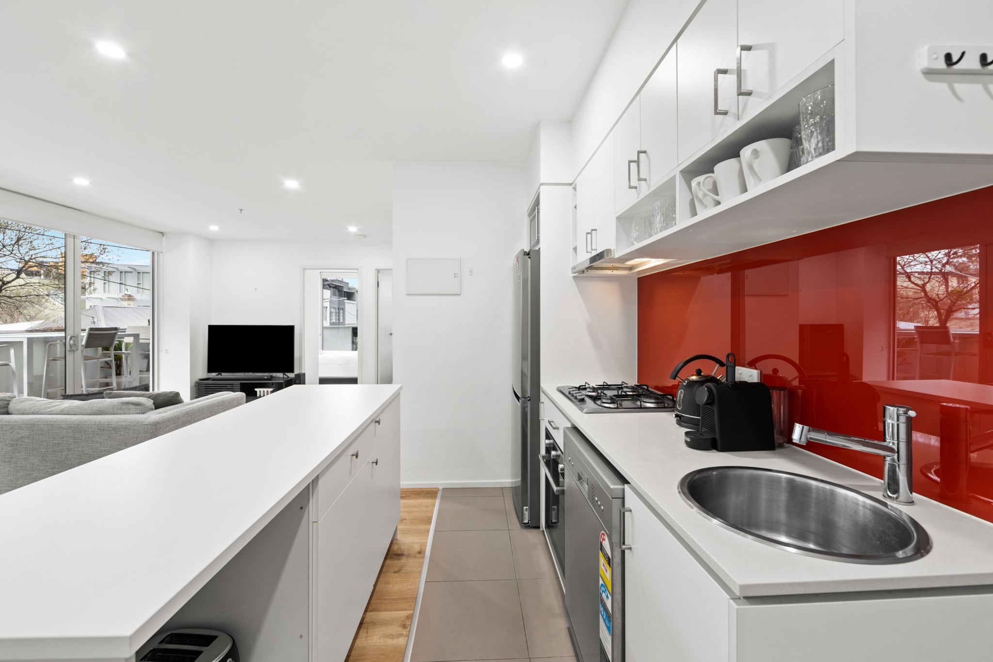 Nestled in the bustling inner-city, this modern 2-bed apartment is perfect if you're looking for cosy chic living in South Yarra. Just a stroll from the stunning Yarra River and the lush Melbourne Botanical Gardens, this charming home features large windows and timeless elegance, promising style, comfort, and easy access to amenities. Only moments away from shops, restaurants, cafes, and transport, it's ideal for people after Melbourne's incredible lifestyle.
The space
This charming 2-bed, 1-bath apartment blends timeless elegance with modern design. The open-plan living area is bright and airy, thanks to large windows that open onto a private balcony with an alfresco dining setup big enough to accommodate 4 people. A fully equipped kitchen and a sleek bathroom are complemented by two beautiful bedrooms filled with natural sunlight. Enjoy year-round comfort with split A/C for heating and cooling in the living area, and benefit from on-site private parking. Nearby, you'll find restaurants, cafes, parks, and convenient public transport options for quick city access. This property will have you feeling like a Melbourne local in no time!
 
Living room
- Couch sits 3 people
- TV with free to air channels & streaming available (guests to use their own credentials)
 
Kitchen & Dining Area
- Fully equipped with utensils and cutlery
- Oven and gas stovetop
- Dining area sits 4 people
 
Bathroom & Laundry
- Laundry room available with washer and dryer
- Travel essentials, towels and hairdryer provided
 
Amenity Notes
- Split system A/C (heating + cooling) in living area
- Portable heater and fan available
- Wi-Fi available
- Basement parking for 1 vehicle
- Amenity access: private undercover balcony with alfresco dining
Local area description
Trendy and affluent, South Yarra is an inner-city suburb of Melbourne. Known for its vibrant lifestyle, upscale shopping, and trendy dining scene, South Yarra is a sought-after destination for both residents and visitors. Its prime location makes it easily accessible by various modes of transportation and its proximity to the CBD ensures convenient connectivity to other parts of Melbourne. One of the most famous streets in South Yarra is Chapel Street, which is renowned for its high-end fashion boutiques, stylish cafes, bars, and restaurants. This shopping and dining precinct offers a mix of fashion-forward stores, vintage shops, and diverse culinary options. Overall, South Yarra is known for its combination of luxury living, cultural offerings, and a bustling commercial scene.
House rules
You are staying in a friendly and peaceful neighbourhood and we kindly ask you to respect the community and your surrounding neighbours. 
 No loud noise between 10 pm and 8 am
- No parties or antisocial behaviour
- No additional people are to access the property without our prior approval
- No pets are allowed in the property without approval
- No smoking is allowed at any times
- If you break something, please let us know
- To help protect all floor coverings, do not wear any shoes inside the property
 
Please be aware that excessive noise such as amplified music, vocals or screaming or anti-social behaviour in the property or common areas can cause neighbours to complain to us, the Building Manager, Council Rangers or Police.
 
IMPORTANT:
- Any breach of the House Rules may lead to a $500 fine plus compensation for any cost/damage created and immediate eviction of the property without refund.
- Pets are available on request unless the property states it is pet friendly. Any stays with pets will incur an additional cleaning fee of $200.
 
Finally, when checking out, we kindly ask you for the following:
 
- Please leave all beds unmade
- Please clean up your dishes and put them away
- In case you have rearranged furniture, please put it back to the original location
- Please take out the rubbish and remember to use the right bins
- Please ensure all appliances, A/C and lights are off and doors and windows are closed.
- Please check your accommodation thoroughly before departing to avoid any unintentional items left behind.
 
We are not liable for any items left behind after your stay. In the rare event that a guest reports a missing item, we will make every effort to locate it for you, but we cannot guarantee its retrieval. If the item is found, we will gladly assist in arranging its return to an address within Australia, subject to postage and service fees.
Interaction with guests
Welcome to MadeComfy! Our local team curates stays in exceptional Australian & New Zealand properties, ensuring style, comfort, and prime locations for discerning guests. We prioritise your needs to provide a memorable home-away-from-home experience. Explore our digital guidebooks for local recommendations, and don't hesitate to contact us throughout your stay. We're here to ensure your comfort - enjoy your stay with MadeComfy.
Notes
For your comfort, this property is prepared with professional-grade hotel-style linen, including a three-sheet setup, ensuring a fresh and hygienic sleep experience.
 
Extra Services:
- Early Check-in: Our standard check-in is at 3 pm. To guarantee early access to the property we suggest booking the night before if available. Otherwise, early check-in is subject to availability from the night before at an additional cost.
- Late check-out: Our standard check-out is at 10 am. To guarantee a later check-out of the property we suggest booking an additional night if available. Otherwise, a late check-out is subject to availability from the night before to an additional cost.
- Baggage: For security reasons, we are unable to receive or to keep unattended baggage before check-in or after check-out
- We provide a small welcome amenity pack to get your stay started.
- For any lost, missing, or unreturned keys, a corresponding monetary fine will be applied to the responsible guest. Please ensure that all keys are returned.
- This booking is protected with coverage for lost baggage and emergency medical expenses, provided by Travel Support with claim upto 500 AUD (T&C Applies). For more details reach out to Guest Support team post booking.
Access description
- The key collection is located offsite and not available 24/7. Further details will be provided 3 days before check-in if your booking is successfully reserved.
- For any lost, missing, or unreturned keys, a corresponding monetary fine will be applied to the responsible guest. Please ensure that all keys are returned.
- The building is wheelchair accessible.
Getting around
Public Transport
The closest bus stop is located 350 m from the property at Chapel St/Alexandra Ave. Please visit Transport Victoria's website for more information.
 
Getting There
The property is located 30 km away from Melbourne Airport. By car, the journey will take around 30 minutes. By public transportation, the journey will take around 1 hour.