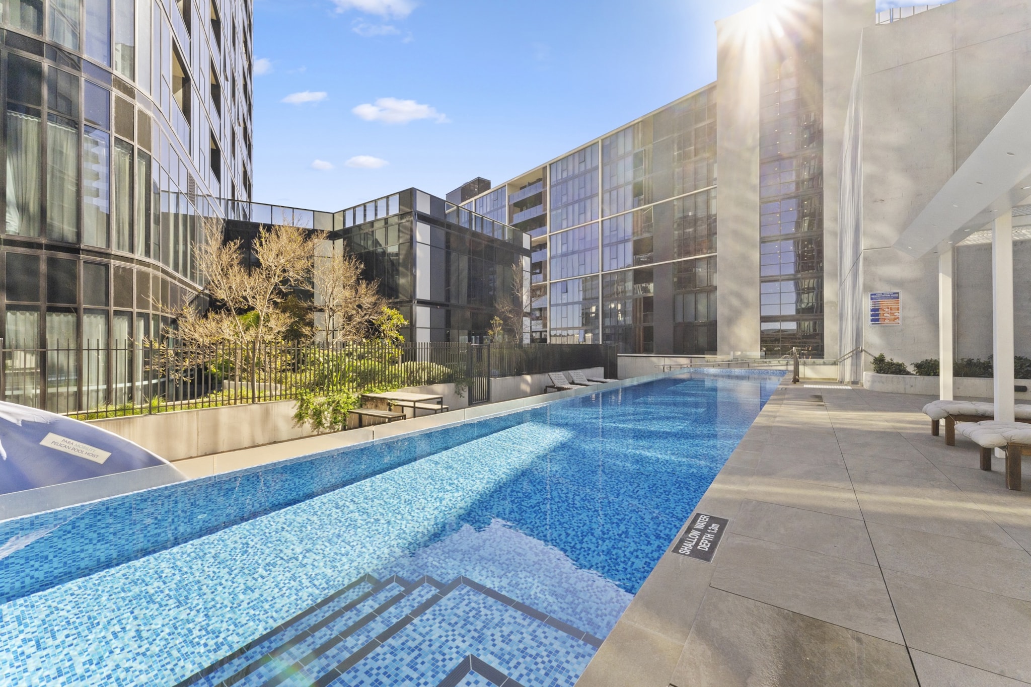 Near Canberra's CBD, this superb lakeside 2-bed apartment with spacious interiors and modern finishes will blow your mind. Minutes away from restaurants, bars, cafes, and natural reserves, guests of this property will enjoy luxurious building amenities. To take a step up your next Canberra trip, there is no place like this Belconnen abode.
The space
With outstanding views of Belconnen's green landscape and the scenic Lake Ginninderra, this modern home includes a spotless kitchen and a comfortable living room with an adjacent private balcony overlooking the unmatched scenery – the perfect place for your morning coffee. With 2 queen-sized bedrooms and 2 spa-like bathrooms, this perfectly located apartment has split A/C, underground parking, internal laundry, and access to deluxe facilities such as an outdoor pool, spa, sauna, cinema room, gym, chef's kitchen, rooftop skypark, outdoor BBQs and lounges. Close to shopping, transport, nature and hospitality venues, upgrade your next Canberra holiday by staying here.
 
Living room
- Couch sits 4 people
- TV with streaming available (guests to use their own credentials)
 
Kitchen & Dining Area
- Fully equipped with utensils and cutlery
- Oven and induction stovetop
- Dining area sits 4 people
 
Bathroom & Laundry
- Laundry room available with washer and dryer
- Travel essentials, towels and hairdryer provided
 
Amenity Notes
- Split A/C (heating + cooling) in living area and main bedroom
- Wi-Fi available
- Underground parking for 2 vehicles
- Amenity access: private balcony with seating; communal outdoor pool, spa, sauna, cinema room, gym, chef's kitchen, rooftop skypark, outdoor BBQs and lounges
Local area description
Belconnen is a suburb situated 7 km from Canberra's CBD. Serving as a prominent commercial and retail hub, it boasts Westfield Belconnen, one of Canberra's largest shopping centres and the esteemed University of Canberra. Belconnen offers ample recreational opportunities, notably around Lake Ginninderra, and is well-connected by a reliable public transport system, including a bus interchange. Its facilities encompass a library, community centres, and sports venues while hosting various cultural and sporting events, providing a dynamic living environment for its residents.
