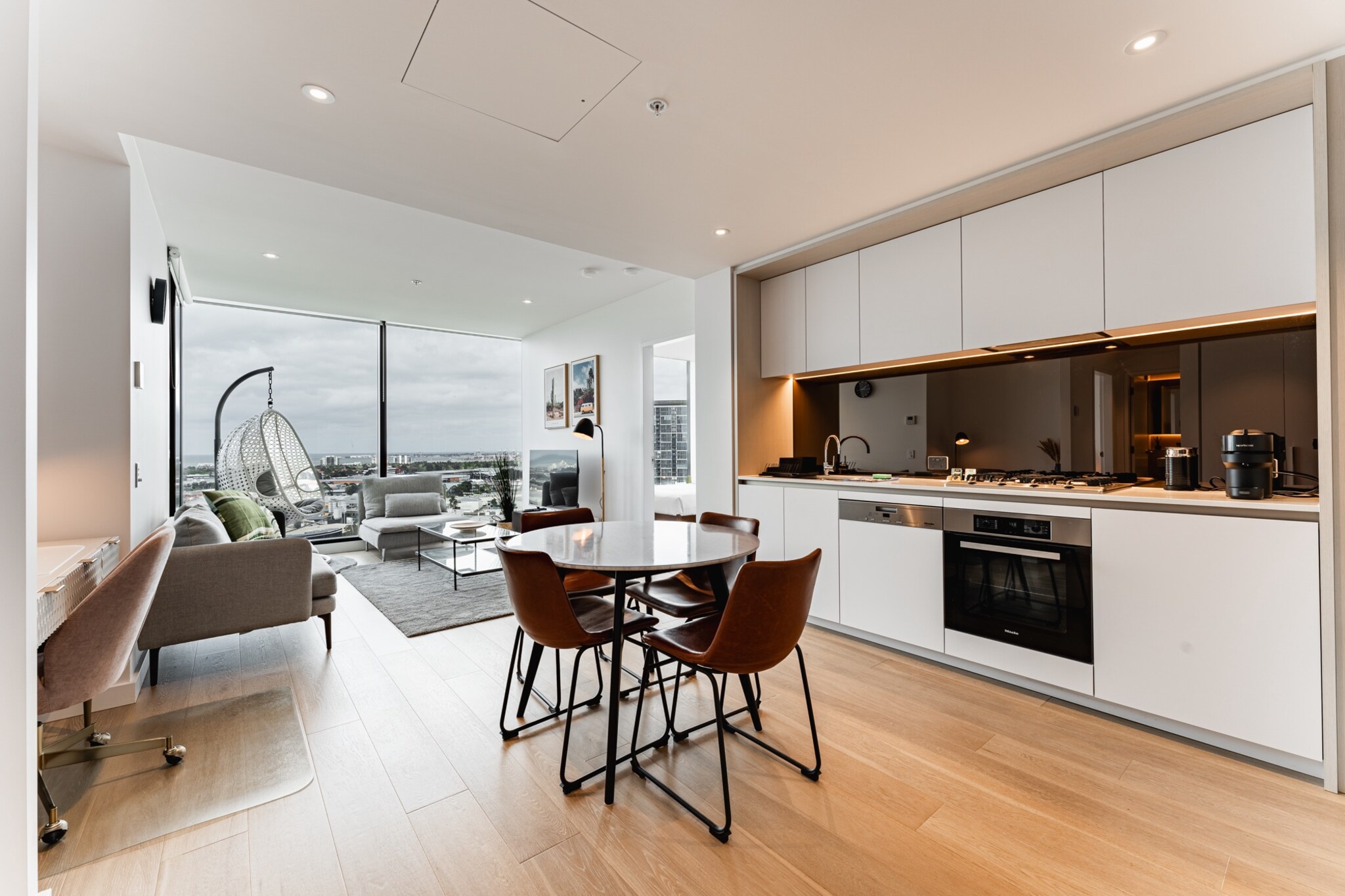 On a high floor, this stunning 2-bed apartment offers modern decor, sweeping harbour views and striking interiors. The building features a variety of luxury amenities, including an indoor swimming pool, gym, and other entertainment areas. The unit is within the free tram zone an steps away from vibrant waterfront dining options, including cafes, restaurants, and bars, you'll always have something to do nearby. Additionally, the Docklands Wharf and the iconic Marvel Stadium are just moments away.
The space
This bright and spacious 2-bed, 1-bath apartment features floor-to-ceiling windows with stunning harbour views. The open-plan layout includes a sleek kitchen, dining area, and a living space with a study nook. Timber floors and sophisticated decor complement the natural light-filled rooms, whilst A/C ensures year-round comfort. Both queen bedrooms include built-in robes, and the bathroom offers a luxurious walk-in rain shower. Step out onto the private balcony overlooking the marina â€“ the perfect morning coffee spot. Additional perks include Wi-Fi, parking, and access to building amenities such as an indoor pool, gym, steam room, and exclusive gourmet kitchen and dining area. With a modern design and prime location, this apartment will take your breath away.
 
Living room
- Couch sits 4 people
- TV with free-to-air channels & streaming available (guests to use their own credentials)
 
Kitchen & Dining Area
- Fully equipped with utensils and cutlery
- Oven and gas stovetop
- Dining area sits 4 people
 
Bathroom & Laundry
- Laundry room available with washer and dryer
- Travel essentials, towels and hairdryer provided
 
Amenity Notes
- Ducted A/C (heating + cooling) in the living area and main bedroom
- Wi-Fi available
- Study Nook in the living area
- Parking for 1 medium-sized vehicle
- Private undercover balcony with seating overlooking marina; communal gym, indoor swimming pool, steam room, members dining room and kitchen
Local area description
Docklands, located on the waterfront in Melbourne, is a modern and bustling suburb characterised by its high-rise residential buildings, commercial spaces, and vibrant cultural scene. Once an industrial port area, Docklands has undergone extensive urban redevelopment, transforming it into a dynamic district with stunning views of Victoria Harbour. With its proximity to the CBD and excellent public transport, Docklands has easy access to amenities, entertainment venues, and recreational activities. Its picturesque waterfront setting also offers harbour cruises, water sports, and more. Docklands offers a unique blend of urban living and waterfront charm, making it an attractive and thriving part of Melbourne.
House rules
You are staying in a friendly and peaceful neighbourhood and we kindly ask you to respect the community and your surrounding neighbours. The following strict House Rules apply:
 
- No loud noise between 10 pm and 8 am
- No parties or antisocial behaviour
- No additional people are to access the property without our prior approval
- No pets are allowed in the property without approval
- No smoking is allowed at any times
- If you break something, please let us know
- To help protect all floor coverings, do not wear any shoes inside the property
 
Please be aware that excessive noise such as amplified music, vocals or screaming or anti-social behaviour in the property or common areas can cause neighbours to complain to us, the Building Manager, Council Rangers or Police.
 
IMPORTANT:
- Any breach of the House Rules may lead to a $500 fine plus compensation for any cost/damage created and immediate eviction of the property without refund.
- Pets are available on request unless the property states it is pet friendly. Any stays with pets will incur an additional cleaning fee of $200.
 
Finally, when checking out, we kindly ask you for the following:
 
- Please leave all beds unmade
- Please clean up your dishes and put them away
- In case you have rearranged furniture, please put it back to the original location
- Please take out the rubbish and remember to use the right bins
- Please ensure all appliances, A/C and lights are off and doors and windows are closed.
- Please check your accommodation thoroughly before departing to avoid any unintentional items left behind.
 
We are not liable for any items left behind after your stay. In the rare event that a guest reports a missing item, we will make every effort to locate it for you, but we cannot guarantee its retrieval. If the item is found, we will gladly assist in arranging its return to an address within Australia, subject to postage and service fees.
Interaction with guests
Welcome to MadeComfy! Our local team curates stays in exceptional Australian & New Zealand properties, ensuring style, comfort, and prime locations for discerning guests. We prioritise your needs to provide a memorable home-away-from-home experience. Explore our digital guidebooks for local recommendations, and don't hesitate to contact us throughout your stay. We're here to ensure your comfort - enjoy your stay with MadeComfy.
Notes
For your comfort, this property is prepared with professional-grade hotel-style linen, including a three-sheet setup, ensuring a fresh and hygienic sleep experience.
 
Extra Services:
- Early Check-in: Our standard check-in is at 3 pm. To guarantee early access to the property we suggest booking the night before if available. Otherwise, early check-in is subject to availability from the night before at an additional cost.
- Late check-out: Our standard check-out is at 10 am. To guarantee a later check-out of the property we suggest booking an additional night if available. Otherwise, a late check-out is subject to availability from the night before to an additional cost.
- Baggage: For security reasons, we are unable to receive or to keep unattended baggage before check-in or after check-out
- We provide a small welcome amenity pack to get your stay started.
- For any lost, missing, or unreturned keys, a corresponding monetary fine will be applied to the responsible guest. Please ensure that all keys are returned.
- This booking is protected with coverage for lost baggage and emergency medical expenses, provided by Travel Support with claim upto 500 AUD (T&C Applies). For more details reach out to Guest Support team post booking.
Access description
- The key collection is onsite. Further details will be provided 3 days before check-in if your booking is successfully reserved.
- For any lost, missing, or unreturned keys, a corresponding monetary fine will be applied to the responsible guest. Please ensure that all keys are returned.
- This property is Wheelchair Accessible.
Getting around
Public Transport
The property is located within the city's free tram zone with the closest tram stop being located 110m from the property on Bourke St/Collins St. Docklands Ferry Wharf is located 800 metres from the property. Please visit Transport Victoria's website for more information.
 
Getting There
The property is located 23 km away from Melbourne Airport. By car, the journey will take around 25 minutes. By public transport, the journey will take around 50 minutes.