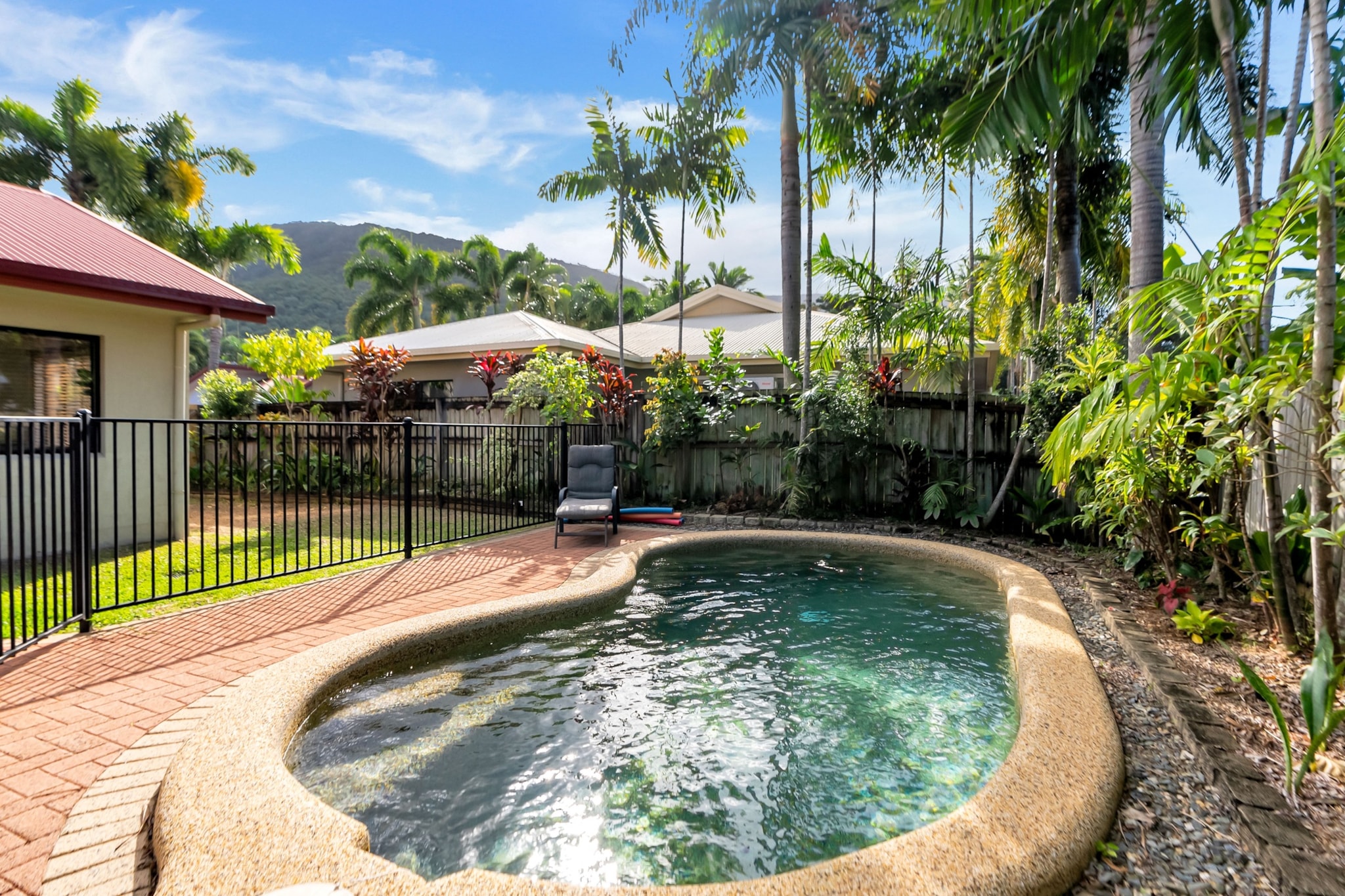 Just a 3-min walk to Clifton Beach, this delightful 3-bed property features spacious interiors, comfortable rooms, and air conditioning. With on-site parking and entertainment options including a heated swimming pool and a BBQ area, it’s ideal for family fun. Nestled in a tranquil setting, you'll be conveniently close to beautiful outdoor destinations such as Palm Cove, Cairns Esplanade, and the lush Kuranda Village. This coastal gem combines convenience and comfort for a memorable getaway!
The space
Looking for the perfect coastal family retreat? This charming 3-bedroom, 2-bath home near Clifton Beach is calling your name. The spacious and homely interiors feature large windows that flood the space with natural light and multiple living and entertaining areas. With a fully equipped kitchen, a comfortable lounge area, and bright dining spaces, the property offers two queen bedrooms and a bunk room, all with comfy bedding and ceiling fans for added comfort. Both bathrooms are polished and stylish and, for climate control, the house has split air conditioning throughout, ensuring comfort in any season. Enjoy the back garden’s BBQ area, alfresco dining, and refreshing swimming pool, perfect for a family day. With driveway parking for 2 vehicles, and easy access to nearby beaches, parks, and attractions, this property won't let you down.
 
Living room
- Couch sits 6 people
- TV with free-to-air channels & streaming available (guests to use their own credentials)
 
Kitchen & Dining Area
- Fully equipped with utensils and cutlery
- Oven and electric stovetop
- Dining area sits 8 people
 
Bathroom & Laundry
- Laundry room available with washer and dryer
- Travel essentials, towels and hairdryer provided
 
Amenity Notes
- Split A/C (heating + cooling) throughout
- Ceiling fans throughout
- Wi-Fi available
- Driveway parking for 2 vehicles
- Amenity access: garden with BBQ area, alfresco dining and a heated swimming pool
Local area description
Clifton Beach is a picturesque suburb located in Far North Queensland, just 20 km north of Cairns. Known for its stunning, sandy shores and relaxed coastal atmosphere, the suburb features a long, pristine beach that's perfect for swimming, sunbathing, and enjoying scenic views of the Coral Sea. Clifton Beach also provides a range of amenities, including parks, local shops, and cafes, making it a popular spot for a peaceful holiday by the seaside.
House rules
You are staying in a friendly and peaceful neighbourhood and we kindly ask you to respect the community and your surrounding neighbours. The following strict House Rules apply:
 
- No loud noise between 10 pm and 8 am
- No parties or antisocial behaviour
- No additional people are to access the property without our prior approval
- No pets are allowed in the property without approval
- No smoking is allowed at any times
- If you break something, please let us know
- To help protect all floor coverings, do not wear any shoes inside the property
 
Please be aware that excessive noise such as amplified music, vocals or screaming or anti-social behaviour in the property or common areas can cause neighbours to complain to us, the Building Manager, Council Rangers or Police.
 
IMPORTANT:
- Any breach of the House Rules may lead to a $500 fine plus compensation for any cost/damage created and immediate eviction of the property without refund.
- Pets are available on request unless the property states it is pet friendly. Any stays with pets will incur an additional cleaning fee of $200.
 
Finally, when checking out, we kindly ask you for the following:
 
- Please leave all beds unmade
- Please clean up your dishes and put them away
- In case you have rearranged furniture, please put it back to the original location
- Please take out the rubbish and remember to use the right bins
- Please ensure all appliances, A/C and lights are off and doors and windows are closed.
- Please check your accommodation thoroughly before departing to avoid any unintentional items left behind.
 
We are not liable for any items left behind after your stay. In the rare event that a guest reports a missing item, we will make every effort to locate it for you, but we cannot guarantee its retrieval. If the item is found, we will gladly assist in arranging its return to an address within Australia, subject to postage and service fees.
Interaction with guests
Welcome to MadeComfy! Our local team curates stays in exceptional Australian & New Zealand properties, ensuring style, comfort, and prime locations for discerning guests. We prioritise your needs to provide a memorable home-away-from-home experience. Explore our digital guidebooks for local recommendations, and don't hesitate to contact us throughout your stay. We're here to ensure your comfort - enjoy your stay with MadeComfy.
Notes
- For your comfort, this property is prepared with professional-grade hotel-style linen, including a three-sheet setup, ensuring a fresh and hygienic sleep experience.
- The garage is not for use.
 
Extra Services:
- Early Check-in: Our standard check-in is at 3 pm. To guarantee early access to the property we suggest booking the night before if available. Otherwise, early check-in is subject to availability from the night before at an additional cost.
- Late check-out: Our standard check-out is at 10 am. To guarantee a later check-out of the property we suggest booking an additional night if available. Otherwise, a late check-out is subject to availability from the night before to an additional cost.
- Baggage: For security reasons, we are unable to receive or to keep unattended baggage before check-in or after check-out
- We provide a small welcome amenity pack to get your stay started.
- This booking is protected with coverage for lost baggage and emergency medical expenses, provided by Travel Support with claim upto 500 AUD (T&C Applies). For more details reach out to Guest Support team post booking.
Access description
- The key collection is located onsite. Further details will be provided 3 days before check-in if your booking is successfully reserved.
- This property is not Wheelchair Accessible.
Getting around
Public Transport
The closest bus stop is located 800 m away from the property on Endeavour Rd at Elford Street. Please visit Translink's website for more information.
 
Getting There
The property is located 23 km away from Cairns Airport. By car, the journey will take around 25 minutes. By public transportation, the journey will take around 2 hours.