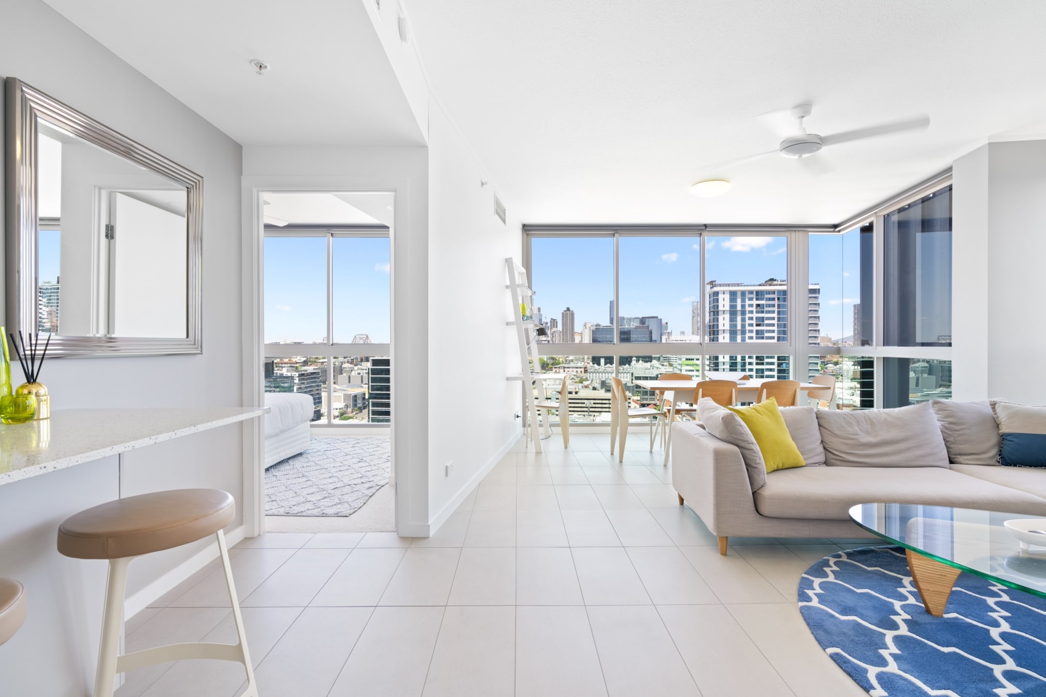 This bright 2-bed apartment is close to Brisbane’s best spots: Fortitude Music Hall is 5 minutes away. Enjoy the city’s nightlife, the Brisbane Riverwalk, the Story Bridge, and the trendy boutiques and cafes along James Street (2-min walk). Floor-to-ceiling windows invite lots of natural light and frame striking skyline views. The property includes air conditioning, and access to a communal rooftop with BBQ facilities and an outdoor dining area, perfect for relaxing or entertaining.
The space
This bright and stylish 2-bed, 2-bath apartment offers a comfortable stay with panoramic skyline views through floor-to-ceiling windows in its open-plan kitchen, dining, and living area. Each bedroom features a queen bed, ceiling fan, and ducted air conditioning for year-round comfort, whilst the sleek bathrooms include modern walk-in showers. The fully equipped kitchen offers contemporary appliances, and a study nook in the living area makes a convenient workspace. Additional amenities include on-site parking, and an internal laundry. Head outdoors to the building's rooftop for the gourmet BBQ area with alfresco dining, perfect for relaxing or entertaining. This thoughtfully designed apartment has all you need for a memorable stay.
Living room
- Couch sits 4 people
- Smart TV with free-to-air channels available and streaming options (Guests to use their own credentials)
Kitchen & Dining Area
- Fully equipped with utensils and cutlery
- Oven and gas stovetop
- Dining area sits 6 people and countertop area sits 2 people
Bathroom & Laundry
- Laundry room available with washer and dryer
- Travel essentials, towels and hairdryer provided
Amenity Notes
- Ducted A/C (heating + cooling) in bedrooms and living area
- Ceiling fans in bedrooms and living area
- Study Nook in living area
- Rooftop with gourmet area equipped with BBQ and alfresco dining
- Parking is available for one car only. Height restriction: 2.1m Suitable for: Small cars or sedans
Local area description
Fortitude Valley, commonly known as "The Valley," is a vibrant inner-city suburb of Brisbane. Steeped in history, it was named after the ship "Fortitude" that transported convicts in the 1820s. Today, it stands as a cultural hub with a thriving arts, music, and nightlife scene, hosting a plethora of live music venues, art galleries, and theatres. The area is renowned for its diverse shopping experiences, ranging from boutique stores to high-end fashion boutiques, with popular precincts like the Emporium and James Street. Fortitude Valley also offers a wide array of dining options, showcasing global cuisines and trendy restaurants. Connected by a railway station and several bus routes, it remains an accessible locale. With an energetic nightlife, the area hosts events and festivals. Fortitude Valley is an ever-evolving, cosmopolitan destination that caters to diverse interests and lifestyles.
House rules
You are staying in a friendly and peaceful neighbourhood and we kindly ask you to respect the community and your surrounding neighbours. The following strict House Rules apply:
- No loud noise between 10 pm and 8 am
- No parties or antisocial behaviour
- No additional people are to access the property without our prior approval
- No pets are allowed in the property without approval
- No smoking is allowed at any times
- If you break something, please let us know
- To help protect all floor coverings, do not wear any shoes inside the property
Please be aware that excessive noise such as amplified music, vocals or screaming or anti-social behaviour in the property or common areas can cause neighbours to complain to us, the Building Manager, Council Rangers or Police.
IMPORTANT:
- Any breach of the House Rules may lead to a $500 fine plus compensation for any cost/damage created and immediate eviction of the property without refund.
- Pets are available on request unless the property states it is pet friendly. Any stays with pets will incur an additional cleaning fee of $200.
Finally, when checking out, we kindly ask you for the following:
- Please leave all beds unmade
- Please clean up your dishes and put them away
- In case you have rearranged furniture, please put it back to the original location
- Please take out the rubbish and remember to use the right bins
- Please ensure all appliances, A/C and lights are off and doors and windows are closed.
- Please check your accommodation thoroughly before departing to avoid any unintentional items left behind.
We are not liable for any items left behind after your stay. In the rare event that a guest reports a missing item, we will make every effort to locate it for you, but we cannot guarantee its retrieval. If the item is found, we will gladly assist in arranging its return to an address within Australia, subject to postage and service fees.
Interaction with guests
Welcome to MadeComfy! Our local team curates stays in exceptional Australian & New Zealand properties, ensuring style, comfort, and prime locations for discerning guests. We prioritise your needs to provide a memorable home-away-from-home experience. Explore our digital guidebooks for local recommendations, and don't hesitate to contact us throughout your stay. We're here to ensure your comfort - enjoy your stay with MadeComfy.
Notes
For your comfort, this property is prepared with professional-grade hotel-style linen, including a three-sheet setup, ensuring a fresh and hygienic sleep experience.
The property is on the 15th floor
Extra Services:
- Early Check-in: Our standard check-in is at 3 pm. To guarantee early access to the property we suggest booking the night before if available. Otherwise, early check-in is subject to availability from the night before at an additional cost.
- Late check-out: Our standard check-out is at 10 am. To guarantee a later check-out of the property we suggest booking an additional night if available. Otherwise, a late check-out is subject to availability from the night before to an additional cost.
- Baggage: For security reasons, we are unable to receive or to keep unattended baggage before check-in or after check-out
- We provide a small welcome amenity pack to get your stay started.
- This booking is protected with coverage for lost baggage and emergency medical expenses, provided by Travel Support with claim upto 500 AUD (T&C Applies). For more details reach out to Guest Support team post booking.
Access description
- The key collection is located offsite 650m away and not available 24/7. Further details will be provided 3 days before check-in if your booking is successfully reserved.
Getting around
Public Transport
The closest bus stop is located 54 m from the property on Ann St at James Street, stop 6. Please visit Translink's website for more information.
Getting There
The property is located 15 km away from Brisbane Airport. By car, the journey will take around 15 minutes. By public transportation, the journey will take around 40 minutes.