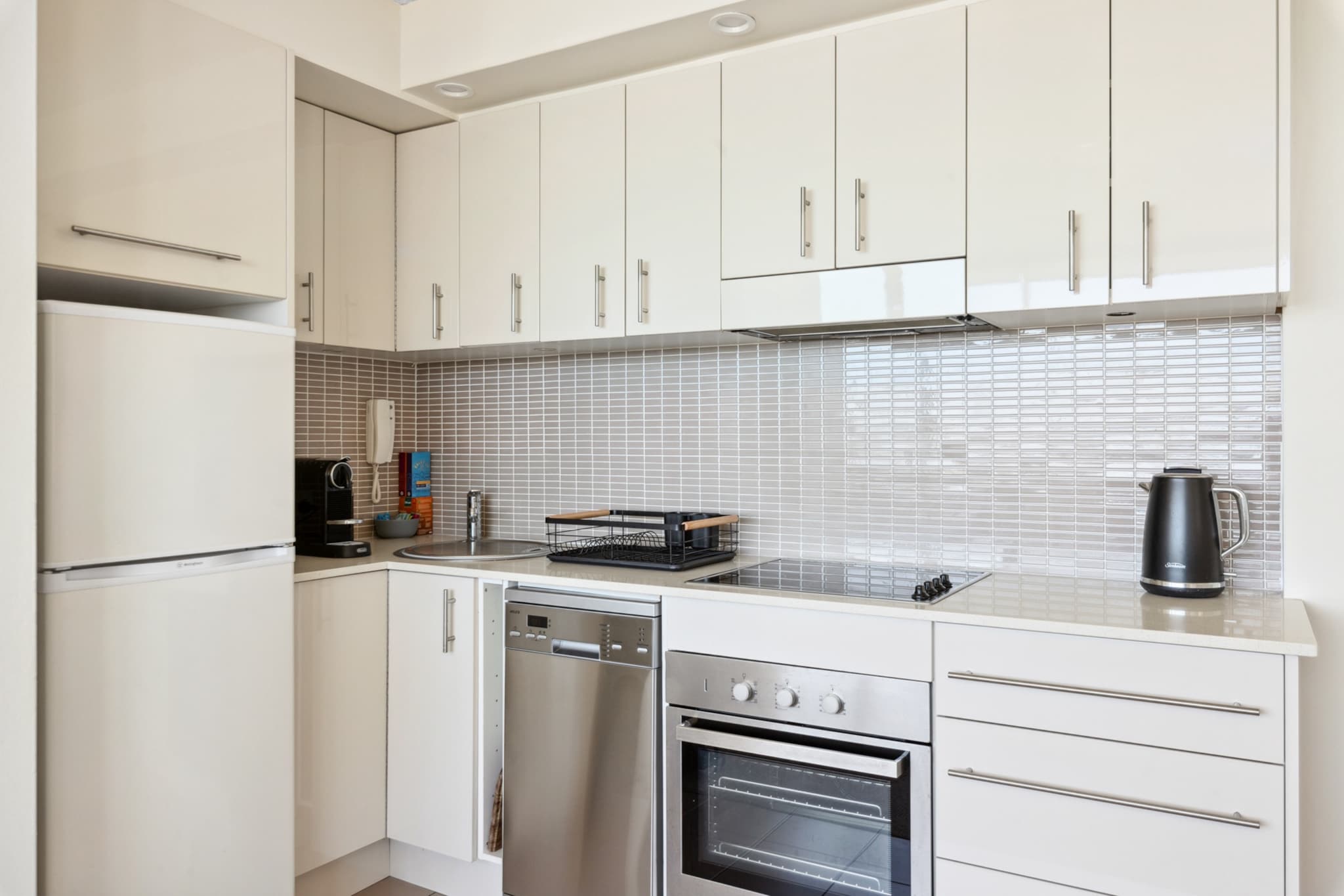 Wake up to the sound of waves and the crisp blue ocean! This bright 1-bed is just 300m from Manly Beach. With modern furnishings and stunning views of the beach, its prime position grants access to local shops, cafes, and restaurants, as well as nearby attractions like Shelly Beach and the Manly Scenic Walkway. Whether you're enjoying the coastal lifestyle or exploring historical sites such as Q Station, this apartment provides the best of Manly and its vibrant Northern Beaches.
The space
This bright and modern 1-bed, 1-bath apartment in Manly offers an open-plan kitchen, living, and dining area with a large window that looks towards the incredible beach and ocean views. The comfortable bedroom, with ocean views, features a queen bed, wall mounted TV and a sleek and modern bathroom, with a walk-in shower for convenience and style. Enjoy the shared amenities, including a communal rooftop outdoor swimming pool and BBQ area, perfect for relaxing and entertaining. With its ideal location, just a short walk to Manly Beach, The Corso, and vibrant dining and shopping options, this property offers the best coastal living with all the modern comforts.
Living room & Bedroom
- Couch sits 2 people + 2 bucket chairs
- Queen bed with wall-mounted TV in the bedroom with free-to-air channels
Kitchen & Dining Area
- Fully equipped with utensils and cutlery
- Oven and electric stovetop
- Dining area sits 2 people (up to 4 with the extendable table + 2 bucket chairs)
Bathroom & Laundry
- A common laundry room is available for guest use. Please note that this facility operates on a pay-per-use basis, and payment is required to access the machines.
- Travel essentials, towels and hairdryer provided
Amenity Notes
- A/C available
- Portable Dyson heater/cooler available
- Wi-Fi is available
- Ocean views of Manly beach
- No parking available
- Communal rooftop outdoor swimming pool and BBQ area