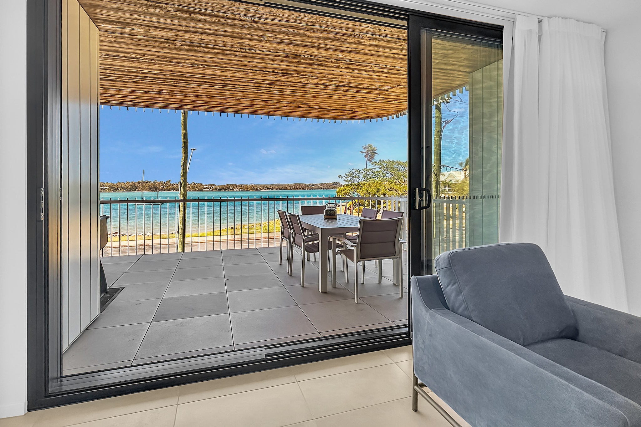 This spacious 3-bed apartment offers an open living space flooded with natural light through large windows. Step out onto the private balcony and enjoy your morning coffee or lunch party overlooking Clyde River. With A/C and on-site parking, you'll be just minutes from stunning attractions like Moruya Heads, and Eurobodalla National Park. Stay here and enjoy modern appliances, a rooftop pool and the natural beauty and wildlife of the region.
The space
Experience ultimate comfort and style in this modern 3-bed, 2-bath apartment featuring an open-plan design. Decorated in elegant earthy tones, this home has a contemporary and calming atmosphere. The well-equipped kitchen features sleek, modern appliances, perfect for cooking meals, whilst the dining space provides ample seating for family or guests. Each of the three bedrooms is designed for comfort, with a king bed in the master, a queen in the second room, and two singles in the third. Both bathrooms boast walk-in showers and elegant finishes. The apartment is fully equipped with A/C, ceiling fans, parking, internal laundry, and Wi-Fi. Outside, your private undercover balcony overlooking the river â€“ with alfresco dining and a BBQ â€“ awaits. Plus, enjoy access to the communal rooftop swimming pool for sunbathing with beautiful views.
 
Living room
- Couch sits 6 people
- TV with free-to-air channels & streaming available (guests to use their own credentials)
 
Kitchen & Dining Area
- Fully equipped with utensils and cutlery
- Oven and induction stovetop
- Dining area sits 8 people and countertop area sits 3 people
 
Bathroom & Laundry
- Laundry room available with washer and dryer
- Travel essentials, towels and hairdryer provided
 
Amenity Notes
- Split A/C (heating + cooling) throughout
- Ceiling fan throughout
- Wi-Fi available
- Underground parking for 1 medium-sized vehicle
- Private undercover balcony with BBQ and alfresco dining
- Communal rooftop swimming pool
Local area description
Batemans Bay, nestled on the stunning south coast of New South Wales, embodies a harmonious blend of coastal charm and natural beauty. As the region's commercial hub, it offers a picturesque waterfront embraced by pristine beaches, including the popular Surfside and Catalina. The Clyde River, weaving through the town, provides a serene backdrop for leisurely activities such as fishing, boating, and kayaking. Its vibrant community celebrates diverse events, from local markets showcasing regional produce to cultural festivals. With its proximity to Murramarang National Park and Eurobodalla National Park, Batemans Bay beckons nature enthusiasts with opportunities for bushwalks, wildlife spotting, and breathtaking scenic lookouts. The town's relaxed ambience, coastal allure, and abundant outdoor pursuits, makes it a captivating destination for residents and tourists.
House rules
You are staying in a friendly and peaceful neighbourhood and we kindly ask you to respect the community and your surrounding neighbours. The following strict House Rules apply:
 
- No loud noise between 10 pm and 8 am
- No parties or antisocial behaviour
- No additional people are to access the property without our prior approval
- No pets are allowed in the property without approval
- No smoking is allowed at any times
- If you break something, please let us know
- To help protect all floor coverings, do not wear any shoes inside the property
 
Please be aware that excessive noise such as amplified music, vocals or screaming or anti-social behaviour in the property or common areas can cause neighbours to complain to us, the Building Manager, Council Rangers or Police.
 
IMPORTANT:
- Any breach of the House Rules may lead to a $500 fine plus compensation for any cost/damage created and immediate eviction of the property without refund.
- Pets are available on request unless the property states it is pet friendly. Any stays with pets will incur an additional cleaning fee of $200.
 
Finally, when checking out, we kindly ask you for the following:
 
- Please leave all beds unmade
- Please clean up your dishes and put them away
- In case you have rearranged furniture, please put it back to the original location
- Please take out the rubbish and remember to use the right bins
- Please ensure all appliances, A/C and lights are off and doors and windows are closed.
- Please check your accommodation thoroughly before departing to avoid any unintentional items left behind.
 
We are not liable for any items left behind after your stay. In the rare event that a guest reports a missing item, we will make every effort to locate it for you, but we cannot guarantee its retrieval. If the item is found, we will gladly assist in arranging its return to an address within Australia, subject to postage and service fees.
Interaction with guests
Welcome to MadeComfy! Our local team curates stays in exceptional Australian & New Zealand properties, ensuring style, comfort, and prime locations for discerning guests. We prioritise your needs to provide a memorable home-away-from-home experience. Explore our digital guidebooks for local recommendations, and don't hesitate to contact us throughout your stay. We're here to ensure your comfort - enjoy your stay with MadeComfy.
Notes
- For your comfort, this property is prepared with professional-grade hotel-style linen, including a three-sheet setup, ensuring a fresh and hygienic sleep experience.
- There may be some noise from the main road.
- The pool may be closed at any time for maintenance.
 
Extra Services:
- Early Check-in: Our standard check-in is at 3 pm. To guarantee early access to the property we suggest booking the night before if available. Otherwise, early check-in is subject to availability from the night before at an additional cost.
- Late check-out: Our standard check-out is at 10 am. To guarantee a later check-out of the property we suggest booking an additional night if available. Otherwise, a late check-out is subject to availability from the night before to an additional cost.
- Baggage: For security reasons, we are unable to receive or to keep unattended baggage before check-in or after check-out
- We provide a small welcome amenity pack to get your stay started.
- This booking is protected with coverage for lost baggage and emergency medical expenses, provided by Travel Support with claim upto 500 AUD (T&C Applies). For more details reach out to Guest Support team post booking.
Access description
- The key collection is located onsite. Further details will be provided 3 days before check-in if your booking is successfully reserved.
Getting around
Public Transport
The closest bus stop is located 52 m from the property on Beach Rd at Herarde St. Please visit Transport NSW website for more information.
 
Getting There
The property is located 29 km away from Moruya Airport. By car, the journey will take around 25 minutes. By public transport the journey will take around 1 hour and 5 minutes.