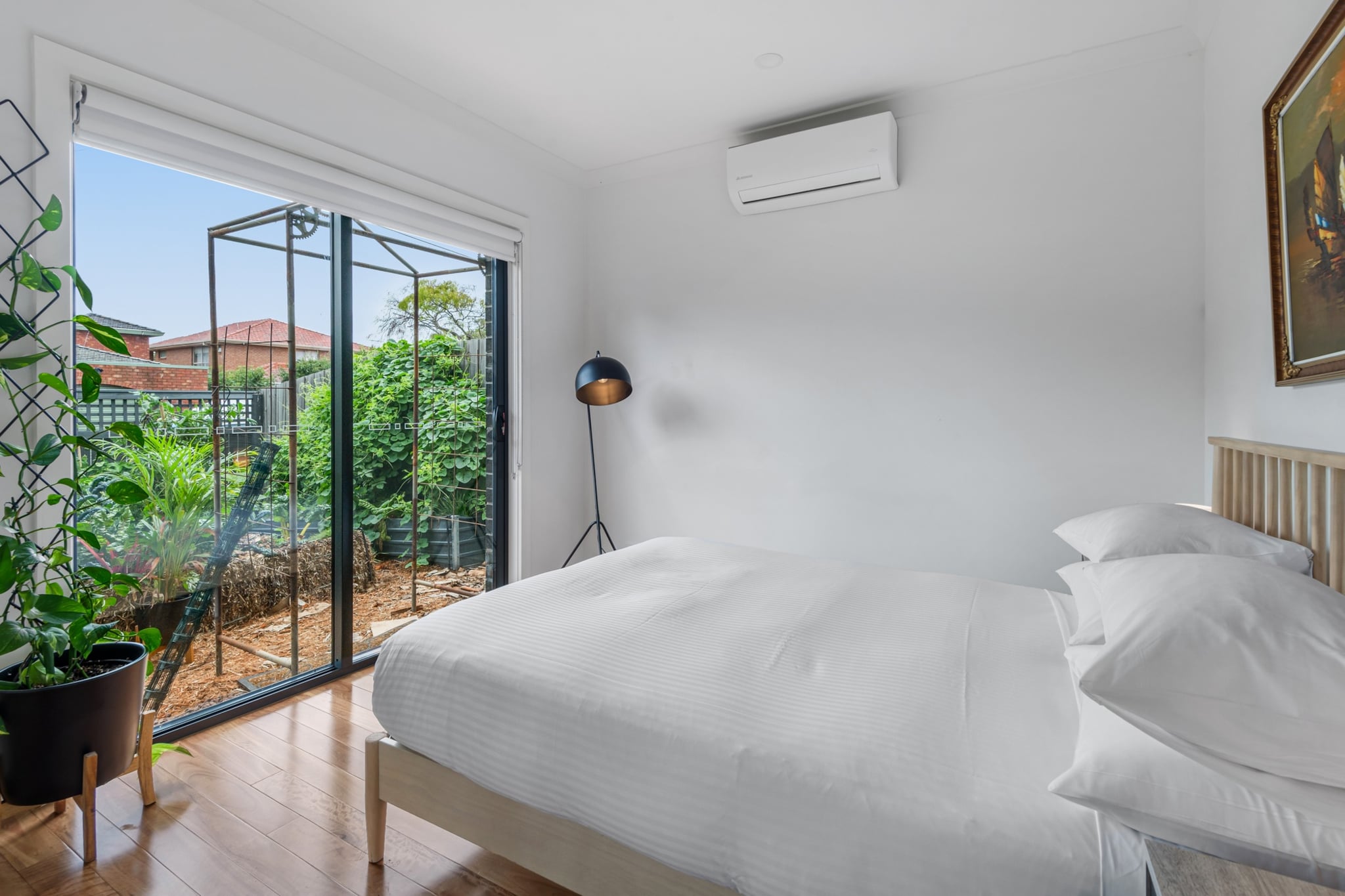 Discover the perfect mix of retro charm and modern convenience in this spacious two-bedroom townhouse in vibrant Coburg. With bold design touches, cosy comforts, and a private courtyard, it’s ideal for couples, families, or friends. Enjoy bright interiors, a full kitchen, blackout blinds, quality bedding, heating, and a private carport. Located near Coburg’s buzzing café scene, markets, green spaces, and transport, this property ensures a seamless stay in a dynamic pocket of Melbourne.
The space
Step into this retro-inspired, 2-bedroom townhouse that blends vintage charm with modern comforts, offering a warm and inviting retreat in the heart of Coburg. Both bedrooms feature queen beds, plush linens, and blackout blinds for a peaceful night's rest. The spacious living area boasts hardwood floors, a cosy four-seater couch and projector perfect for unwinding after a day of exploring. The fully equipped kitchen includes a gas stovetop, electric oven, and all the cooking essentials you’ll need, while the adjoining dining area seats six—ideal for enjoying meals with loved ones or hosting a small gathering. Natural light fills the townhouse, complemented by stylish décor and thoughtful touches throughout. Additional conveniences include onsite parking in a private carport, a private balcony with seating, and a laundry room. Situated close to Coburg's vibrant shops, cafés, and public transport, this townhouse is your perfect base for exploring the suburb's lively character and Melbourne's must-see attractions.
Living Room
-Comfortable couch that seats 4 people
-Projector & speakers for TV viewing
Kitchen & Dining Area
-Fully equipped with cutlery and utensils
-Gas stovetop and electric oven
-Dining area with seating for 6
Bathroom & Laundry
-Private laundry room with washer and dryer
-Fresh towels, travel essentials, and a hairdryer provided
Amenity Notes
-Onsite parking in a private carport
-A/C in living area and bedrooms
-Wi-Fi available
-Private courtyard with seating