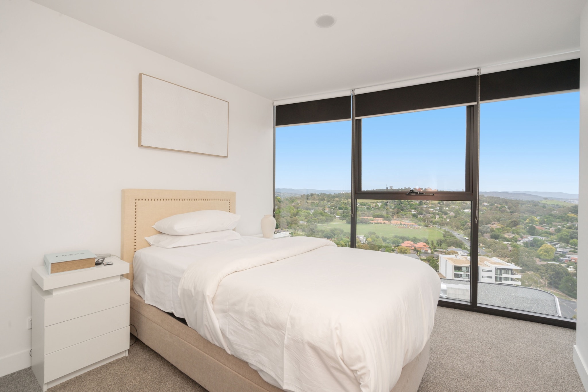 Immerse yourself in comfort at this chic 2-bedroom, 2-bathroom apartment in Phillip, ACT. Relax in a light-filled open-plan living space with modern dÃ©cor and balcony views. Ideal for families or couples, it features air conditioning, a private laundry, and on-site parking. Guests enjoy access to a pool, gym, and sauna, while being steps from shops and public transport. Self-check-in ensures a seamless stay in this vibrant location.
The space
Step into this beautifully appointed apartment, where comfort meets style. The property offers two spacious bedrooms, each with a king bed and single bed, plush linens, and blackout blinds to ensure restful nights. The main bedroom boasts an en-suite for added privacy, while a second bathroom caters to additional guests. A sunlit living area features a cosy three-seater couch and a large TV with streaming options. The fully equipped kitchen includes an electric stovetop, oven, and a dining table seating six. Outdoors, a private balcony offers a perfect retreat, with comfortable seating to enjoy serene views. The property also includes a private laundry with a washer and dryer, making longer stays a breeze. Guests can unwind in the shared building amenities, including a pool, sauna, gym, cinema room, and lounge area. Thoughtful touches, like air conditioning in the lounge and bedrooms, ensure year-round comfort.
 
Living Room
-Couch seats 3 people
-TV with streaming services (guests to use own credentials)
 
Kitchen & Dining Area
-Fully equipped with utensils and cutlery
-Electric stovetop and oven
-Dining area seats 6
 
Bathroom & Laundry
-En-suite in the main bedroom and shared bathroom
-Private laundry with washer and dryer
-Travel essentials, towels, and hairdryer provided
 
Amenity Notes
-Underground parking for 1 vehicle (max height: 2.1m)
-Air conditioning in lounge room and main bedroom
-Wi-Fi is available
-Study nook in living area
-Private balcony with seating for 6
-Building amenities: pool, sauna, gym, cinema, and lounge
Local area description
Located in the heart of Phillip, this apartment places you within walking distance of local shops, cafes, and parks. Explore nearby Westfield Woden, indulge in a variety of dining options, or enjoy a relaxing day at Eddison Park. With Canberra city centre just 15 minutes away, this location combines convenience and vibrant local charm.
House rules
You are staying in a friendly and peaceful neighbourhood and we kindly ask you to respect the community and your surrounding neighbours. The following strict House Rules apply:
 
- No loud noise between 10 pm and 8 am
- No parties or antisocial behaviour
- No additional people are to access the property without our prior approval
- No pets are allowed in the property without approval
- No smoking is allowed at any times
- If you break something, please let us know
- To help protect all floor coverings, do not wear any shoes inside the property
 
Please be aware that excessive noise such as amplified music, vocals or screaming or anti-social behaviour in the property or common areas can cause neighbours to complain to us, the Building Manager, Council Rangers or Police.
 
IMPORTANT:
- Any breach of the House Rules may lead to a $500 fine plus compensation for any cost/damage created and immediate eviction of the property without refund.
- Pets are available on request unless the property states it is pet friendly. Any stays with pets will incur an additional cleaning fee of $200.
 
Finally, when checking out, we kindly ask you for the following:
 
- Please leave all beds unmade
- Please clean up your dishes and put them away
- In case you have rearranged furniture, please put it back to the original location
- Please take out the rubbish and remember to use the right bins
- Please ensure all appliances, A/C and lights are off and doors and windows are closed.
- Please check your accommodation thoroughly before departing to avoid any unintentional items left behind.
 
We are not liable for any items left behind after your stay. In the rare event that a guest reports a missing item, we will make every effort to locate it for you, but we cannot guarantee its retrieval. If the item is found, we will gladly assist in arranging its return to an address within Australia, subject to postage and service fees.
Interaction with guests
Welcome to MadeComfy! Our local team curates stays in exceptional Australian & New Zealand properties, ensuring style, comfort, and prime locations for discerning guests. We prioritise your needs to provide a memorable home-away-from-home experience. Explore our digital guidebooks for local recommendations, and don't hesitate to contact us throughout your stay. We're here to ensure your comfort - enjoy your stay with MadeComfy.
Notes
For your comfort, this property is prepared with professional-grade hotel-style linen, including a three-sheet setup, ensuring a fresh and hygienic sleep experience.
 
Extra Services:
- Early Check-in: Our standard check-in is at 3 pm. To guarantee early access to the property we suggest booking the night before if available. Otherwise, early check-in is subject to availability from the night before at an additional cost.
- Late check-out: Our standard check-out is at 10 am. To guarantee a later check-out of the property we suggest booking an additional night if available. Otherwise, a late check-out is subject to availability from the night before to an additional cost.
- Baggage: For security reasons, we are unable to receive or to keep unattended baggage before check-in or after check-out
- We provide a small welcome amenity pack to get your stay started.
 
- Window and facade cleaning works will be done from late July for 6 weeks on weekdays, please expect some noise and limited access to the rooftop.
- This booking is protected with coverage for lost baggage and emergency medical expenses, provided by Travel Support with claim upto 500 AUD (T&C Applies). For more details reach out to Guest Support team post booking.
Access description
Key collection is offsite. Further details will be provided 3 days before check-in if your booking is successfully reserved.
Getting around
Public Transport
Bus routes operate nearby, connecting to Canberra CBD and surrounding suburbs.
 
Getting There
The property is a 10-minute drive from Canberra Airport and 15 minutes from Canberra city centre.