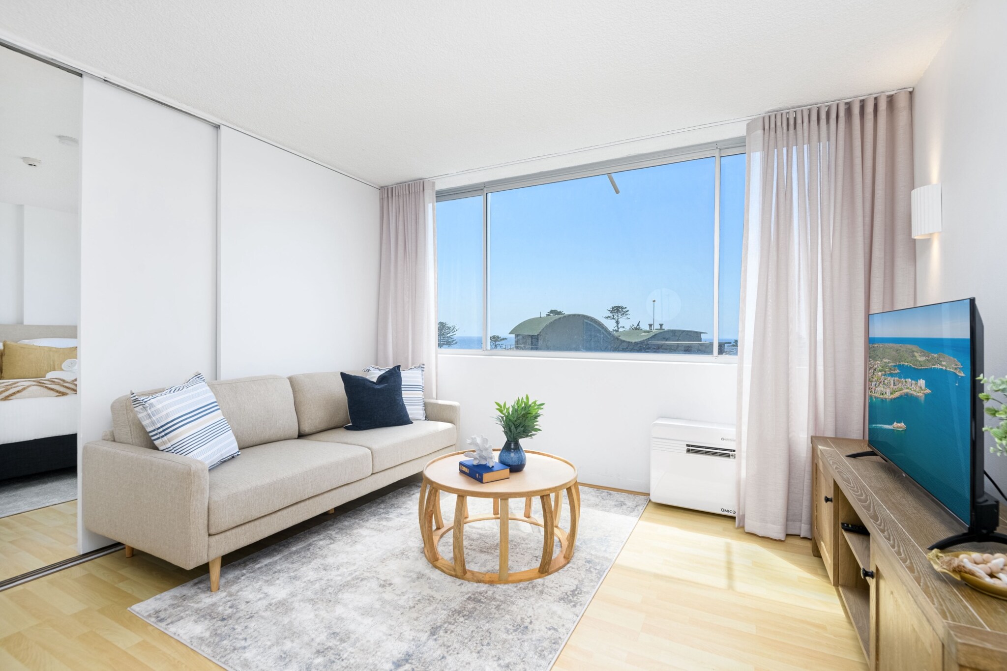 Stay in the heart of Manly at this stylish 1-bed apartment, just moments from the beach, cafÃ©s, and transport. Featuring a bright living space, a well-equipped kitchen, and access to a rooftop with a pool and BBQ, this retreat is perfect for couples or solo travellers. Enjoy free-to-air TV, Wi-Fi, and self-check-in for a seamless stay. With shops, restaurants, and the ferry nearby, experience the best of Sydneyâ€™s coastal lifestyle right from your doorstep.
The space
This inviting 1-bedroom apartment offers a comfortable and stylish retreat in the heart of Manly. The bright living area features a cosy two-seater couch, a TV with free-to-air channels, and an open-plan layout leading to a functional kitchen. The bedroom is fitted with a queen-sized bed, blackout blinds for restful sleep, and a private en-suite bathroom. The well-equipped kitchen boasts an electric oven and stovetop, plus all essential cookware and cutlery for home-cooked meals. The kitchen island doubles as a charming eat-in area with two comfortable high stools. Residents can enjoy access to premium building amenities, including a rooftop with stunning city and ocean views, a communal pool, and a BBQ areaâ€”perfect for unwinding after a day at the beach. A communal laundry is available for added convenience. Located just steps from Manly Beach, the ferry terminal, and vibrant dining options, this apartment is a perfect coastal escape.
 
Living Room
-Couch seats 2 people
-TV with free-to-air channels and Chromecast (guests to use their own credentials)
 
Kitchen & Dining Area
-Fully equipped with cutlery and utensils
-Oven and electric stovetop
-Dining area seats 2
 
Bathroom & Laundry
-Ensuite bathroom with travel essentials and towels
-Communal laundry with coin-operated washer and dryer
-Hairdryer provided
 
Amenity Notes
-No parking
-Air conditioning in the living room
-Wi-Fi is available
-Communal rooftop outdoor swimming pool and BBQ area
Local area description
Nestled in Sydneyâ€™s iconic beachside suburb, Manly offers a relaxed coastal lifestyle with endless attractions. Take a short stroll to the golden sands of Manly Beach, perfect for surfing and sunbathing. Explore The Corso, lined with boutique shops, cafÃ©s, and restaurants. The Manly Ferry provides a scenic 30-minute ride to Circular Quay, making city access a breeze.

