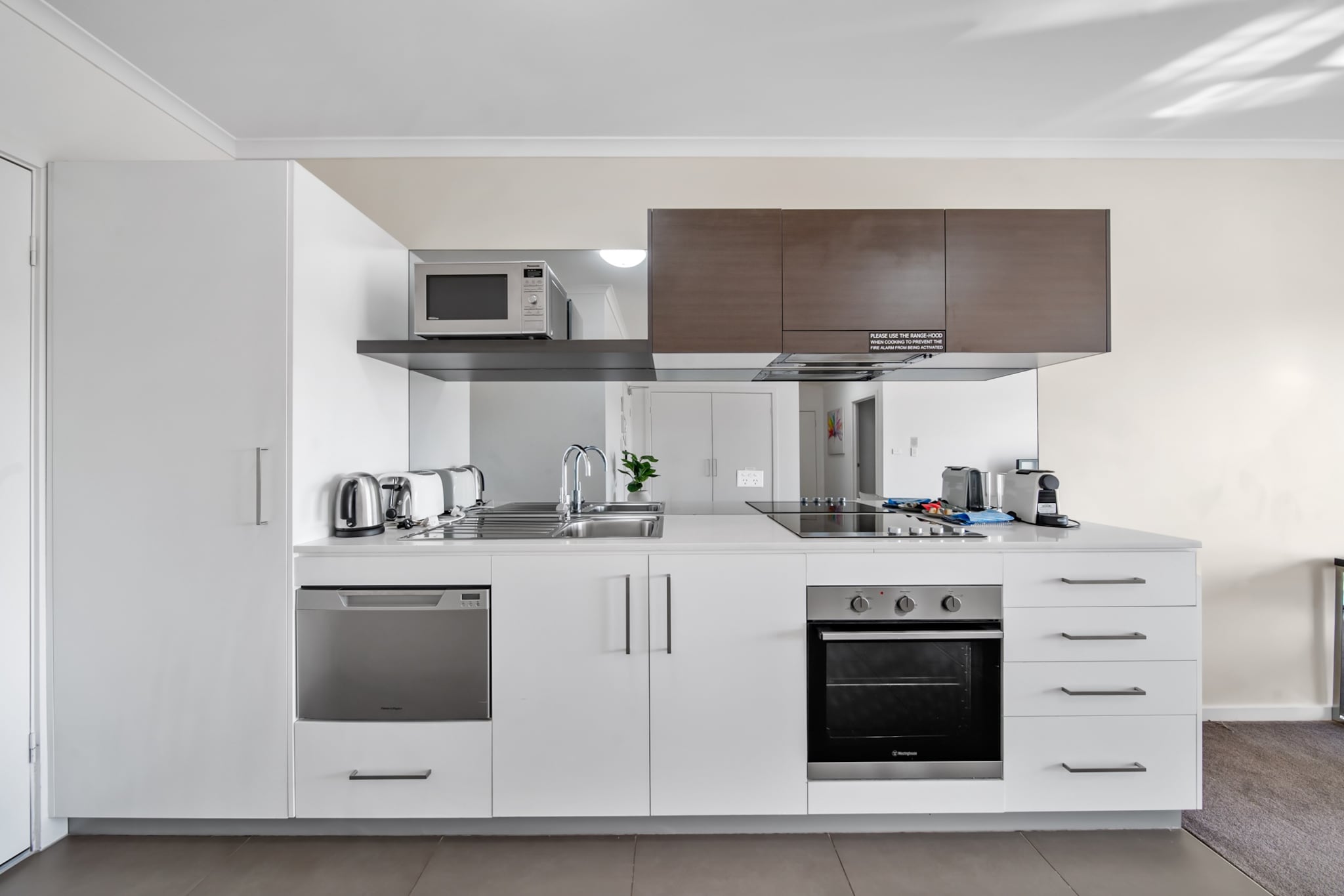 Experience style and convenience in this spacious 1-bedroom apartment in Greenway. Featuring a king bed, open-plan living, and a private balcony, it’s perfect for couples or solo travellers. Enjoy a fully equipped kitchen, on-site underground parking, and self-check-in via lockbox. Located near shops, dining, and public transport, this bright, modern space offers a comfortable stay with easy access to Canberra’s attractions.
The space
This stylish 1-bedroom, 1-bathroom apartment offers a contemporary retreat designed for comfort. The open-plan living area is spacious and light-filled, featuring a couch and TV, blackout blinds in both the living area and bedroom ensure restful sleep, while a king-size bed adds a touch of luxury. The modern kitchen is fully equipped with electric appliances, including an oven, stovetop, microwave, and dishwasher. A private balcony extends the living space, inviting guests to relax outdoors. The private laundry room is fitted with a washer and dryer for added convenience. With underground parking, secure building access, and self-check-in, this apartment is the perfect choice for both short and extended stays.
 
Living Room
-Couch seats 4 people
-TV with free-to-air channels
 
Kitchen & Dining Area
-Fully equipped with cutlery and utensils
-Oven and electric stovetop
-Dining area seats 4
 
Bathroom & Laundry
-Laundry room available with washer and dryer
-Travel essentials, towels, and hairdryer provided
 
Amenity Notes
-Onsite underground parking (1 space, height limit 2.1m)
-Wall-mounted A/C (heating + cooling) in the living area
-Study nook in the living area
Local area description
Greenway is a vibrant suburb in Canberra’s south, known for its scenic surroundings and convenient amenities. Enjoy lakeside walks at Lake Tuggeranong, shopping and dining at South.Point Shopping Centre, and outdoor recreation at Tuggeranong Town Park. With easy access to public transport and major roads, Greenway offers a peaceful yet connected lifestyle, perfect for both leisure and business travellers.
House rules
You are staying in a friendly and peaceful neighbourhood and we kindly ask you to respect the community and your surrounding neighbours. The following strict House Rules apply:
 
- No loud noise between 10 pm and 8 am
- No parties or antisocial behaviour
- No additional people are to access the property without our prior approval
- No pets are allowed in the property without approval
- No smoking is allowed at any times
- If you break something, please let us know
- To help protect all floor coverings, do not wear any shoes inside the property
 
Please be aware that excessive noise such as amplified music, vocals or screaming or anti-social behaviour in the property or common areas can cause neighbours to complain to us, the Building Manager, Council Rangers or Police.
 
IMPORTANT:
- Any breach of the House Rules may lead to a $500 fine plus compensation for any cost/damage created and immediate eviction of the property without refund.
- Pets are available on request unless the property states it is pet friendly. Any stays with pets will incur an additional cleaning fee of $200.
 
Finally, when checking out, we kindly ask you for the following:
 
- Please leave all beds unmade
- Please clean up your dishes and put them away
- In case you have rearranged furniture, please put it back to the original location
- Please take out the rubbish and remember to use the right bins
- Please ensure all appliances, A/C and lights are off and doors and windows are closed.
- Please check your accommodation thoroughly before departing to avoid any unintentional items left behind.
 
We are not liable for any items left behind after your stay. In the rare event that a guest reports a missing item, we will make every effort to locate it for you, but we cannot guarantee its retrieval. If the item is found, we will gladly assist in arranging its return to an address within Australia, subject to postage and service fees.
Interaction with guests
Welcome to MadeComfy! Our local team curates stays in exceptional Australian & New Zealand properties, ensuring style, comfort, and prime locations for discerning guests. We prioritise your needs to provide a memorable home-away-from-home experience. Explore our digital guidebooks for local recommendations, and don't hesitate to contact us throughout your stay. We're here to ensure your comfort - enjoy your stay with MadeComfy.
Notes
For your comfort, this property is prepared with professional-grade hotel-style linen, including a three-sheet setup, ensuring a fresh and hygienic sleep experience.
 
Extra Services:
- Early Check-in: Our standard check-in is at 3 pm. To guarantee early access to the property we suggest booking the night before if available. Otherwise, early check-in is subject to availability from the night before at an additional cost.
- Late check-out: Our standard check-out is at 10 am. To guarantee a later check-out of the property we suggest booking an additional night if available. Otherwise, a late check-out is subject to availability from the night before to an additional cost.
- Baggage: For security reasons, we are unable to receive or to keep unattended baggage before check-in or after check-out
- We provide a small welcome amenity pack to get your stay started.
- This booking is protected with coverage for lost baggage and emergency medical expenses, provided by Travel Support with claim upto 500 AUD (T&C Applies). For more details reach out to Guest Support team post booking.
Access description
Key collection is onsite. Further details will be provided 3 days before check-in if your booking is successfully reserved.
Getting around
Public Transport: Bus stops nearby offer services to Woden, Canberra CBD, and surrounding suburbs.
 
Getting There: The property is approximately a 25-minute drive from Canberra Airport and 20 minutes from Canberra CBD.