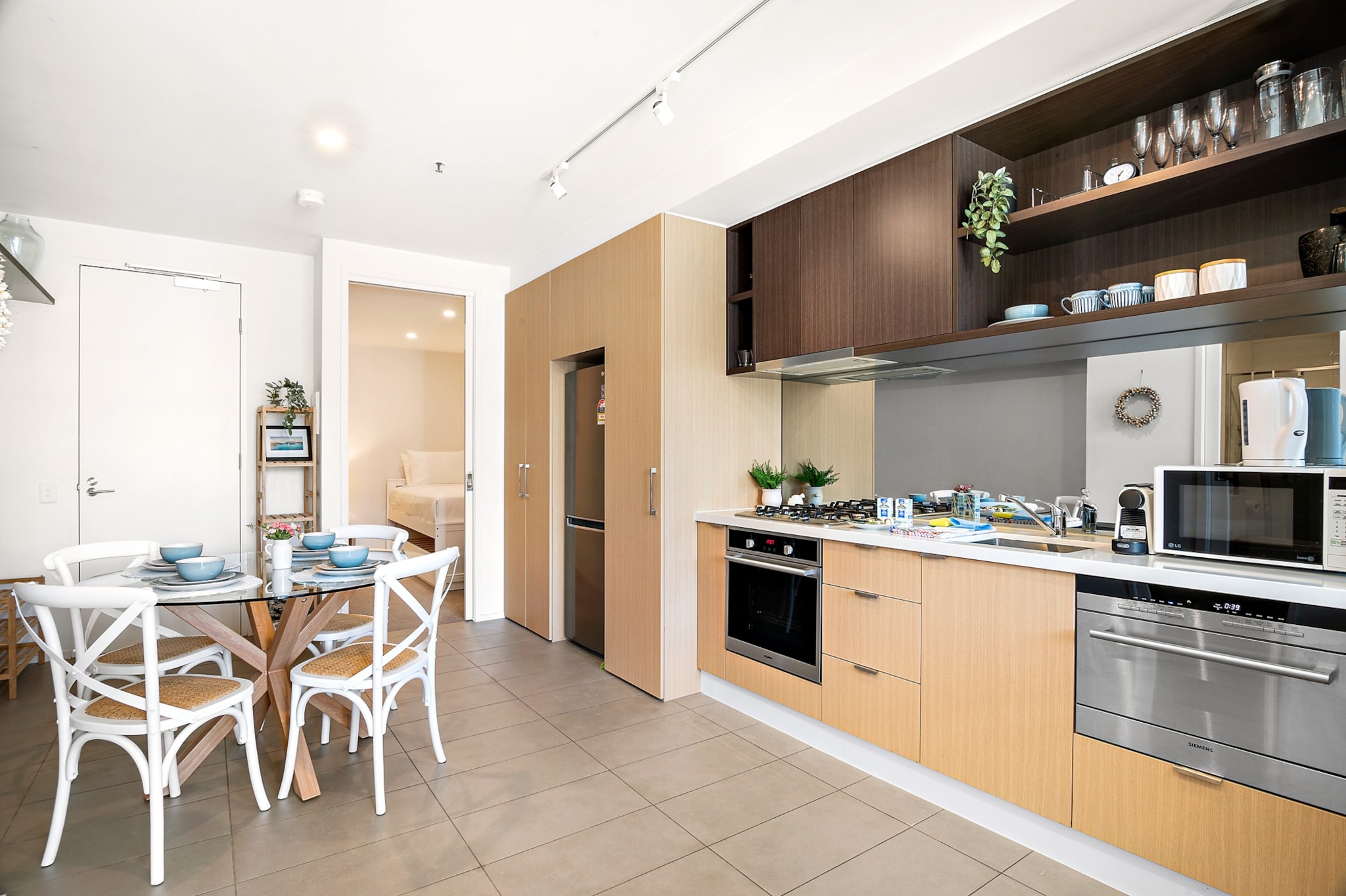 Stay in the heart of St Kilda in this bright and modern 2-bedroom apartment, just steps from Acland Street, Luna Park, and the beach. Featuring a queen and single bed, a well-equipped kitchen, and a comfortable living area, this stylish space is perfect for couples, small families, or business travellers. Enjoy easy access to public transport, vibrant cafés, and scenic coastal walks while experiencing the best of Melbourne’s beachside lifestyle.
The space
This inviting 2-bedroom apartment offers a blend of modern style and comfort in St Kilda’s vibrant heart. The open-plan living area features a spacious 4-seater couch, stylish décor, and a TV with streaming access. Large windows allow natural light to fill the space, creating a warm and welcoming atmosphere. The kitchen is well-equipped with all essential appliances, making home dining effortless. The bedrooms offer a restful retreat, with a queen bed in the master and a single bed in the second bedroom, both with blackout blinds for added comfort. The sleek bathroom includes a walk-in shower, travel essentials, and fresh towels.
For year-round comfort, the living area has air conditioning, while a portable fan and heater are available in the master bedroom. With Acland Street’s bustling cafés, shops, and trams just moments away, and iconic attractions like Luna Park and St Kilda Beach within walking distance, this apartment is perfect for exploring Melbourne’s famous coastal suburb.
Living Room:
-Couch seats 4 people
-TV with Free-to-Air and streaming (guests to use their own credentials)
Kitchen & Dining Area:
-Fully equipped with cutlery and utensils
-Oven and gas stovetop
-Dining area seats 4
Bathroom & Laundry:
-Laundry available with washer only
-Travel essentials, towels, and hairdryer provided
Amenity Notes:
-No onsite parking; paid street parking available nearby.
-Air conditioning in the living area
-Portable fan and heater in the master bedroom
-Wi-Fi is available
Local area description
St Kilda is a lively seaside suburb known for its bustling cafés, iconic attractions, and stunning waterfront. Acland Street is just moments away, offering boutique shopping, renowned bakeries, and vibrant nightlife. Take a scenic stroll along the St Kilda Foreshore, visit the historic Luna Park, or catch a live show at The Palais Theatre. With trams providing quick access to the CBD, St Kilda is the perfect blend of beachside charm and city convenience.
House rules
You are staying in a friendly and peaceful neighbourhood and we kindly ask you to respect the community and your surrounding neighbours. The following strict House Rules apply:
- No loud noise between 10 pm and 8 am
- No parties or antisocial behaviour
- No additional people are to access the property without our prior approval
- No pets are allowed in the property without approval
- No smoking is allowed at any times
- If you break something, please let us know
- To help protect all floor coverings, do not wear any shoes inside the property
Please be aware that excessive noise such as amplified music, vocals or screaming or anti-social behaviour in the property or common areas can cause neighbours to complain to us, the Building Manager, Council Rangers or Police.
IMPORTANT:
- Any breach of the House Rules may lead to a $500 fine plus compensation for any cost/damage created and immediate eviction of the property without refund.
- Pets are available on request unless the property states it is pet friendly. Any stays with pets will incur an additional cleaning fee of $200.
Finally, when checking out, we kindly ask you for the following:
- Please leave all beds unmade
- Please clean up your dishes and put them away
- In case you have rearranged furniture, please put it back to the original location
- Please take out the rubbish and remember to use the right bins
- Please ensure all appliances, A/C and lights are off and doors and windows are closed.
- Please check your accommodation thoroughly before departing to avoid any unintentional items left behind.
We are not liable for any items left behind after your stay. In the rare event that a guest reports a missing item, we will make every effort to locate it for you, but we cannot guarantee its retrieval. If the item is found, we will gladly assist in arranging its return to an address within Australia, subject to postage and service fees.
Interaction with guests
Welcome to MadeComfy! Our local team curates stays in exceptional Australian & New Zealand properties, ensuring style, comfort, and prime locations for discerning guests. We prioritise your needs to provide a memorable home-away-from-home experience. Explore our digital guidebooks for local recommendations, and don't hesitate to contact us throughout your stay. We're here to ensure your comfort - enjoy your stay with MadeComfy.
Notes
For your comfort, this property is prepared with professional-grade hotel-style linen, including a three-sheet setup, ensuring a fresh and hygienic sleep experience.
Extra Services:
- Early Check-in: Our standard check-in is at 3 pm. To guarantee early access to the property we suggest booking the night before if available. Otherwise, early check-in is subject to availability from the night before at an additional cost.
- Late check-out: Our standard check-out is at 10 am. To guarantee a later check-out of the property we suggest booking an additional night if available. Otherwise, a late check-out is subject to availability from the night before to an additional cost.
- Baggage: For security reasons, we are unable to receive or to keep unattended baggage before check-in or after check-out
- We provide a small welcome amenity pack to get your stay started.
- This booking is protected with coverage for lost baggage and emergency medical expenses, provided by Travel Support with claim upto 500 AUD (T&C Applies). For more details reach out to Guest Support team post booking.
Access description
The key collection is offsite. Further details will be provided 3 days before check-in if your booking is successfully reserved.
Getting around
Public Transport:
St Kilda trams provide direct access to Melbourne’s CBD, with nearby stops connecting to major train stations and city attractions.
Getting There:
The apartment is approximately a 30-minute drive from Melbourne Airport and a 15-minute drive from the CBD.