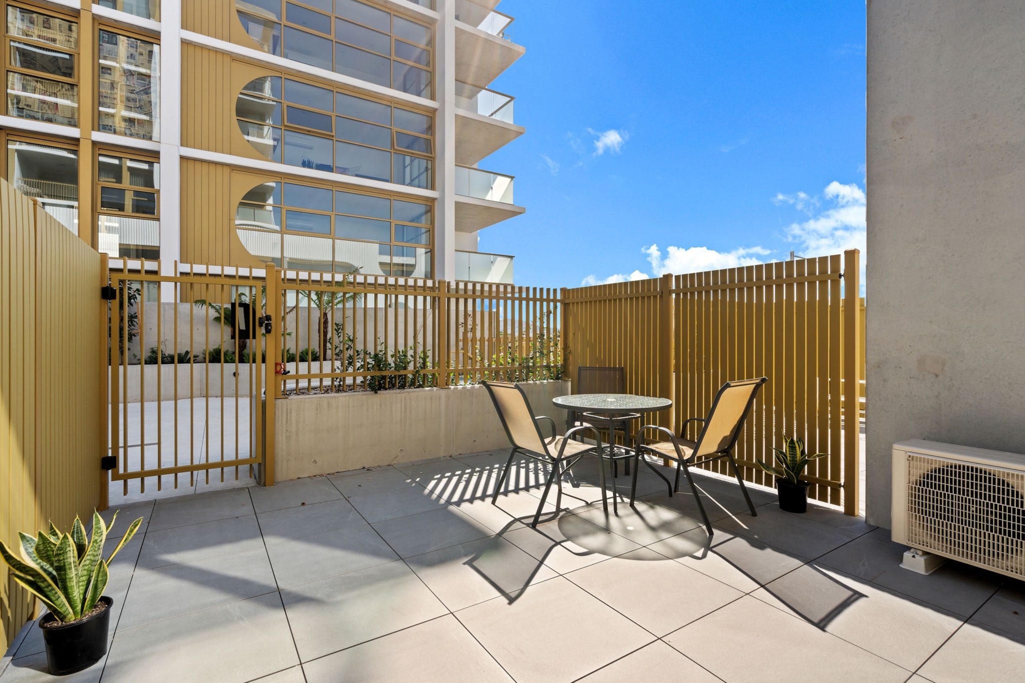 This modern 1-bedroom apartment in Denman Prospect offers a stylish and convenient stay. Ideal for solo travellers or couples, it features a comfortable living area, a well-equipped kitchen, private courtyard and communal outdoor pool. Enjoy easy access to local shops, parks, and public transport. With self-check-in and amenities like air conditioning, heating, and on-site parking, this apartment is the perfect choice for your next stay.
The space
This contemporary loft-style apartment offers a relaxing and bright atmosphere, with spacious interiors and modern finishes. The open-plan layout features a fully equipped kitchen with electric appliances and a comfortable living area with a large sofa and TV. The bedroom, with a double bed, offers a restful retreat. The apartment’s private courtyard provides an outdoor space for relaxation or venture out to the communal pool for a refreshing dip. The stylish interior includes laminate flooring, and the bathroom is well-appointed, completing the perfect space for your stay.
Living Room
-Couch seats 3 people
-TV with all streaming platforms (guests to use their own credentials)
Kitchen & Dining Area
-Fully equipped with cutlery and utensils
-Oven and electric stovetop
-Countertop seats 2
Bathroom & Laundry
-Laundry room available with washer only
-Travel essentials and towels provided
Amenity Notes
-On-site parking is available in an underground car park (1 space)
-A/C (heating + cooling) in the living room
-1 Portable heater available
-Wi-Fi is available
-Private courtyard with outdoor seating for 3
-Communal outdoor pool
Local area description
Denman Prospect is a peaceful suburb in the Molonglo Valley, offering easy access to shopping, parks, and public transport. Nearby attractions include the National Arboretum, Stromlo Forest Park, and Lake Burley Griffin. It’s the perfect location for guests seeking a tranquil environment with easy access to Canberra’s city centre.
House rules
You are staying in a friendly and peaceful neighbourhood and we kindly ask you to respect the community and your surrounding neighbours. The following strict House Rules apply:
- No loud noise between 10 pm and 8 am
- No parties or antisocial behaviour
- No additional people are to access the property without our prior approval
- No pets are allowed in the property without approval
- No smoking is allowed at any times
- If you break something, please let us know
- To help protect all floor coverings, do not wear any shoes inside the property
Please be aware that excessive noise such as amplified music, vocals or screaming or anti-social behaviour in the property or common areas can cause neighbours to complain to us, the Building Manager, Council Rangers or Police.
IMPORTANT:
- Any breach of the House Rules may lead to a $500 fine plus compensation for any cost/damage created and immediate eviction of the property without refund.
- Pets are available on request unless the property states it is pet friendly. Any stays with pets will incur an additional cleaning fee of $200.
Finally, when checking out, we kindly ask you for the following:
- Please leave all beds unmade
- Please clean up your dishes and put them away
- In case you have rearranged furniture, please put it back to the original location
- Please take out the rubbish and remember to use the right bins
- Please ensure all appliances, A/C and lights are off and doors and windows are closed.
- Please check your accommodation thoroughly before departing to avoid any unintentional items left behind.
We are not liable for any items left behind after your stay. In the rare event that a guest reports a missing item, we will make every effort to locate it for you, but we cannot guarantee its retrieval. If the item is found, we will gladly assist in arranging its return to an address within Australia, subject to postage and service fees.
Interaction with guests
Welcome to MadeComfy! Our local team curates stays in exceptional Australian & New Zealand properties, ensuring style, comfort, and prime locations for discerning guests. We prioritise your needs to provide a memorable home-away-from-home experience. Explore our digital guidebooks for local recommendations, and don't hesitate to contact us throughout your stay. We're here to ensure your comfort - enjoy your stay with MadeComfy.
Notes
-There are stairs leading to the apartment and inside the apartment
-Apartment is loft style
For your comfort, this property is prepared with professional-grade hotel-style linen, including a three-sheet setup, ensuring a fresh and hygienic sleep experience.
Extra Services:
- Early Check-in: Our standard check-in is at 3 pm. To guarantee early access to the property we suggest booking the night before if available. Otherwise, early check-in is subject to availability from the night before at an additional cost.
- Late check-out: Our standard check-out is at 10 am. To guarantee a later check-out of the property we suggest booking an additional night if available. Otherwise, a late check-out is subject to availability from the night before to an additional cost.
- Baggage: For security reasons, we are unable to receive or to keep unattended baggage before check-in or after check-out
- We provide a small welcome amenity pack to get your stay started.
- This booking is protected with coverage for lost baggage and emergency medical expenses, provided by Travel Support with claim upto 500 AUD (T&C Applies). For more details reach out to Guest Support team post booking.
Access description
Key collection is onsite. Further details will be provided 3 days before check-in if your booking is successfully reserved.
Getting around
Public Transport
Bus services operate nearby, providing quick access to Canberra’s city centre and beyond. The nearest bus stops are just a short walk from the property.
Getting There
The property is approximately a 25-minute drive from Canberra International Airport and just 15 minutes from the city centre.